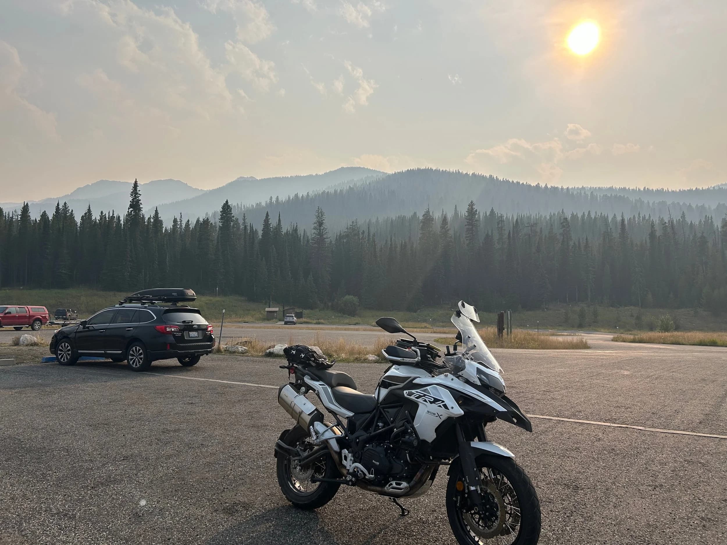 Trip Report: NW National Parks Loop
I left my job recently to take a much needed sabbatical and figure out what I’m doing next. A few weeks after my last day at work I embarked on what was to be a three week tour of NW-ish National Parks from Portland, to include Olympic, North Cascades, Glacier, Yellowstone, Grand Teton, Craters of the Moon, Lassen Volcanic, and Crater Lake.
I ended up missing Grand Tetons due to weather and I had to cut the trip short before I got to Lassen (family medical issue), so Lassen and Crater Lake remain unvisited.
Trip Dates: Sept 3 - Sept 16 (13 days)
Total Travel Miles: 3478 (does not include local miles for store runs, etc.)
Total Gallons of Gas Used: 82
Equipment: 2021 Benelli TRK502X Gaia GPS & Google Maps running on Sonim XP8 rugged Android phoneButler Motorcycle Maps (paper maps of best M/C roads in the country) iPhone 14 (main camera) Akaso Brave 7 helmet-mounted adventure camera Spot X satellite communicator and tracker Wolfman Luggage WP waterproof tank bag and saddle bags (no longer available) Watershed Colorado dry bag duffel (across the pillion seat) Kriega US-5 Drypack (tail bag) Kriega 3L hydration backpack (strapped to duffel, not worn)Marmot Ajax 2 tent Nemo hydrophobic down sleeping bag (non-mummy)Helinox ultralight cot MSR WhisperLite International stove
(Purchased in 1991 for my first moto trip: Detroit, MI to San Diego and back on an XT250)Gossamer Gear Bare Boxer bear-proof food canisters (two - one in each saddle bag)
Day 1 - Olympic National Park Date: Tuesday 9/3/2024
Destination: South Beach Campground, Olympic National Park
Travel Time: 4h 24m
Miles: 213Notes:
Planned to head west to Astoria then north from there, but left later than expected so headed up I-5 to US 12. I’ve driven/ridden that stretch of I-5 hundreds of times (starting in 1993). It’s boring and I hate it.
South Beach CG is first-come-first-served. I didn’t have issue getting a site. There is a long, tight loop of sites along the coastline, but I chose one of the sites further back near the bathrooms due to wind concerns. The bathroom building provided a sort of wind shelter for my site.
I used the heated grips on this leg; it was pretty chilly along the coast in the Olympic Peninsula. I almost didn’t install them, thinking I was being paranoid about the cold. I ended up using them a lot.
Day 2 - Ferry to Seattle / Burien Date: Wednesday 9/4/2024
Destination: Friend’s house in Burien, WA
Travel Time: 7h 30m
Miles: 199
Notes:
Slept well (thanks to Advil PM). I’ve not been sleeping well for more than a year. I’m really hoping to reset my sleep patterns with this trip. A good night’s sleep is one of my great joys and I feel like I’ve been robbed of that pleasure.
Used my Aeropress this morning for the first time ever. I’m hooked.
Headed up along US 101 through Port Angeles and then down to the Southworth ferry terminal near Port Orchard. Ferried across to Fauntleroy, which is just a few miles north my friend’s house in Burien. I’m always surprised at how long it takes to get from the Olympic Peninsula to the east side of Puget Sound (Seattle, etc.). With the ferry crossing (I love ferries) it took seven and a half hours to go 200 miles.
Discovered at my first stop of the day (just up 101 at the Kalaloch Campground, stopped to refill water) that the battery is quite weak and won’t start the bike if you leave the ignition on for even two minutes without the motor running. This would become a theme for the next few days. Fortunately, I have a jumper box and a permanent jump harness wired to the battery so jump starts are a quick operation.
Had a good evening with old friends.
Day 3 - North Cascades via Mountain Loop RoadDate: Thursday 9/5/2024
Destination: Newhalem Campground, North Cascades National Park
Travel Time: 4h 30m
Miles: 146Notes:
Slept well, on the couch. No pills needed.
I realized yesterday that my summer riding gloves (Rev’It Dune) were a size (or two) too small. Rev’It gloves fit really tight and I feel like I can never get it quite right. And yet, I love them. So, I stopped at a Cycle Gear in Bellevue to pick up something summer weight (Dirt 3) that fit better. They’re better, but maybe still one size too small. Such is life.
From Bellevue, I rode north and took the Mountain Loop Hwy then on up north to North Cascades. It was a hot ride. Still summer.
A small section of the Mountain Loop Road is dirt/gravel, which I didn’t realize. No biggie. Was just surprised (clearly I didn’t study my maps closely enough). When riding solo on a bike that weighs over 500 lbs., I tend to avoid planning much off-pavement riding. That’s what my DR-Z is for.
Day 4 - Newport, Washington via Winthrop Date: Friday 9/6/2024
Destination: Golden Spur Motor Inn, Newport, Washington
Travel Time: 8h
Miles: 308
Notes:
Slept just ok, even with Advil PM.
Pretty ride through North Cascades National Park and Colville National Forest. Didn’t do any backroads or hikes. Discovered (new to me) the town of Winthrop. Stopped for coffee at Sheri’s and resupplied on freeze-dried food at Cascades Outdoor Store.
The town of Newport is almost nothing, but, inexplicably, there’s an amazing restaurant (Brownell’s Place). Had dinner and a few ciders. Met and chatted with the owner/chef (she’s great). Listened to some live music. Then back to the motel.
Day 5 - New Battery in Kalispell Date: Saturday 9/7/2024
Destination: West Glacier KOA, West Glacier, MT
Travel Time: 8h 7m
Miles: 293
Notes:
Slept well on motel bed (on sleeping bag, not in the sheets). Another hot one.
Discovered that the water pump seal leaks oil. A quick post in the TRK Facebook group revealed that this is a common problem on this bike, and and easy fix. It’s apparently just a bad o-ring.
Battery has been getting continuously worse, and now requires I jump start the bike about every other start. Google Maps to the rescue: directions to the Batteries Plus in Kalispell, please. They don’t have an Odyssey AGM in the right size; the Duracell will have to do. (It’s been great.)
I set up camp at the West Glacier KOA, which will be my base for a few days. KOAs are their own little world. Very strange. Not really my thing, but the on-site laundry was handy.
After setting up camp I opened a cider and used the iPad to book a vehicle reservation for the next day to ride Going to the Sun Road, which I really wanted to do.
Day 6 - Going to the Sun RoadDate: Sunday 9/8/2024
Destination: Local Ride: West Glacier, Going to the Sun Road, Saint Mary, East Glacier
Travel Time: 5h 35m
Miles: 142Notes:
Quick breakfast and gas up in West Glacier before entering Going to the Sun Road.
Going to the Sun Road was stunning. This was the first point in the trip where I had tingles and was giddy at what I was seeing.
Took a very short hike along Saint Mary Lake. Again, I was beside myself with the beauty.
Lunch at the general store in Kiowa.
The rest of the ride back after East Glacier was meh, but I just kept thinking about how amazing what I’d seen in the morning had been.
Dinner at the KOA. Tacos from a cart (ok / not great, and a very weird guacamole) and a few glasses of wine from another cart. I asked about the guac and it turns out they make it in a food processor. Come on, people.
Day 7 - Ride to BozemanDate: Monday 9/9/2024
Destination: Friend’s house in Bozeman, Montana
Travel Time: ~ 8h (Gaia crashed near the end of the trip, but before getting to Bozeman)
Miles: ~ 400Notes:
Slept poorly again. No pills this time. Took some photos of my soft luggage setup to answer some questions in the TRK502X Facebook group. The saddle bags are from Wolfman Luggage, but I don’t think they make this waterproof line anymore. I use a duffel dry bag from Watershed across the top. A heat shield protects the side bag from exhaust heat.
Hazy, smoky ride most of the way. Very windy in places. This is where I first really started to feel how underpowered the TRK502 is. Really struggled in places.
Developed an engine-speed-sensitive squeak or rattle. Sounds like when a heat shield vibrates in resonance with engine vibration. Discovered that it’s a missing crash bar mounting bolt allowing the crash bar to rub against the frame.
Also noticed that there’s a resonant oscillation at speed that feels like the chain going bad (like it’s stretching unevenly).
First of several nights at a friend’s house in Bozeman (which, it turns out, is a pretty cool town). And there’s a hot tub…
Day 8 - Bike Maintenance & Hyalite ReservoirDate: Tuesday 9/10/2024
Destination: Local Ride: Hyalite Reservoir
Travel Time: not recorded
Miles: not recordedNotes:
Woke up to a smoky sunrise. I had the best night’s sleep I’ve had in years. This is was the whole point of this trip: to untangle my burnout and reclaim sleep as one of my joys. I wrote about it in my journal when I woke up. I hope this wasn’t a fluke.
Planned to replace the bolt that rattled loose from the crash bar, but instead discovered that it had actually severed off at the mount point. No fixing that on the road. Adjusted chain and moved on.
Lunch at Mountains Walking Brewery in Bozeman.
Rode up to Hyalite Reservoir. Pretty ride. Smoky still.
Soaked in hot tub after dinner.
Day 9 - North Yellowstone LoopDate: Wednesday 9/11/2024
Destination: Northern loop through Yellowstone National Park
Travel Time: 9h 36m
Miles: 272Notes:
Did a day trip from Bozeman down through the northern loop in Yellowstone, entering at Mammoth and taking the scenic route through Paradise Valley.
Saw elk, coyotes (I think), buffalo, and pronghorn.
Pretty ride, but cold in places. Used heated grips again.
Rode the loop through Mammoth Hot Springs (see video) at the end.
Coffee at Tumbleweed Bookstore & Cafe in Gardiner. I kind of dig Gardiner. Good vibe.
Had dinner at Mountains Walking Brewing. Rain and wind started. Lights flickered. Waited for rain to stop before riding back to the house.
Power out at the house due to high winds. This does not bode well for tomorrow.
Day 10 - Winter Weather in the ParksDate: Thursday 9/12/2024
Destination: Grand Teton National Park via West Yellowstone Pocatello, Idaho
Travel Time: 5h 40m
Miles: 201Notes:
Today was supposed to be a gorgeous ride through Yellowstone into Grand Teton National Park, and camping at Signal Mountain CG in the park. The weather had other ideas. It was pouring rain (and cold) all the way to West Yellowstone from Bozeman. By the time I got to West Yellowstone I was getting severe winter weather warnings on my phone calling for up to 3 (three!!) inches of snow accumulating in the high passes in the park. It’s bad enough in a car, but that’s a disaster waiting to happen on a motorcycle.
I parked my butt at Mountain Mama’s Cafe in West Yellowstone to warm up / dry off and decide what to do. I almost had myself convinced to push through when I realized that, even if I made it to the campground ok, I’d be setting up camp in the rain and I’d likely be miserable all night. Grand Teton would have to wait.
From West Yellowstone it’s easy to bail west into Idaho and get away from the park weather and elevations. So that’s what I did. It was not a pleasant ride, though. I was in torrential downpours all the way to Idaho Falls.
Arriving in Idaho Falls, I was exhausted and sure I could just find a room for the night. I dropped the bike at a roundabout (short-legged it coming to a stop; I knew it was going so I just rolled away). Guy behind me helped me pick it up. Then, there were no rooms because it was move in week for the two universities there (U of I, ISU). This would become a recurring theme.
I rode further to Blackfoot. Still no rooms.
I called ahead to Pocatello and got a room at a Red Lion there. I was never so happy to be off the bike.
No pictures this day. I couldn’t even get the action camera to turn on.
Day 11 - Craters of the Moon and EBR-1Date: Friday 9/13/2024
Destination: Craters of the Moon National Monument
Travel Time: 4h 20m
Miles: 124
Notes:
I wasn’t sure what my destination would be today but my plan was to do a little nuclear tourism, see Craters of the Moon, and then go somewhere from there. My schedule and day-plan was thrown off by missing Grand Teton National Park and spending a night in Pocatello, which was not on the itinerary at all.
Stopped in Atomic City. Not sure why; I was under the impression that Atomic City was the first city lit by nuclear engergy, but it was practically a ghost town. There are a few houses there, but as far as I could tell all of the business were shuttered. Except, maybe, for the race track; that looked like it might still get used.
Arco, it turns out, is the city celebrated as the first in the world to be lit by nuclear energy. Nothing special about the town, but they do a nice job of making City Hall photo-worthy.
Between Atomic City and Arco is EBR-1 (Experimental Breeder Reactor I) which was the world’s first breeder reactor. The EBR-1 exhibit was closed for the season, but in the lot next to it were some really interesting experimental nuclear heat-transfer jet engines that never made it out of the experimental phase (probably a good thing).
Craters of the Moon is pretty small. If you don’t do any of the walks, it’s literally just a 30 minute road loop. Still, it was an unexpected surprise and delight. I had no idea what to expect but I was positively chuffed at the experience. I noticed that the campground had open sites so I inquired at the entry booth. As luck would have it, the whole campground is first come / first serve. I decided to set up for the night. It’s good to be done early and have some time to read and not stress about making distance.
Day 12 - New Chain in Twin FallsDate: Saturday 9/14/2024
Destination: Battle Mountain, Nevada
Travel Time: 8h 52m
Miles: 335
Notes:
Beautiful morning in Craters of the Moon. While I was breaking camp a parade of classic cars came into the park to drive the loop. I got a picture of one Pontiac down the road in Carey at a gas station.
Carey ended up being an unplanned fork in the road for me. I discovered this morning that my chain was indeed stretching unevenly, and the oscillation I was feeling and hearing was the chain hum changing from a “loose” hum to a “tight” hum rapidly as the tight spot moved around the sprockets. I was supposed to continue west to Mountain Home and then south from there into Nevada. A very scenic route, according to my Butler map. But, between camp and the gas station I got pretty paranoid about the chain snapping at high speed, which, worst case, could lead to a fatal crash.
So I called ahead to a few motorcycle dealers in Mountain Home (on my planned route) to see if they could take me in and replace the chain. No dice. This is the downside of having an obscure motorcycle from an obscure marque - no one wants to work on it. Making matters worse this is an Italian-designed bike built in China, a fact which causes many people to lose the ability to think clearly. “It’s Chinese junk!” Not so. Next.
With Mountain Home out, I tried Twin Falls. My first call was to Adventure Motorsports, and the service manager there took me in with no hesitation. “How soon can you be here?” I didn’t get his name, but my hat’s off to him and his one tech working furiously on a Saturday to beat the 3pm closing time. He said during high season, they get about 15-20 out of town travelers per week who need something done, and they take them all in. I love to hear stuff like this. This shop is in it for the community. They have a nice showroom, too.
With a quality new chain installed, I got a burrito and a MexiCoke at a Mexican place and went on my way. I made it to Battle Mountain, NV, where I decide to get a room. Tomorrow I rejoin my planned scenic route. Day 13 - Desert Mountains in NV, CADate: Sunday 9/15/2024
Destination: Grizzly Campground, Lake Davis (near Portola, CA)
Travel Time: 7h
Miles: 307
Notes:
I love the northern Nevada landscape, and today’s ride didn’t disappoint. US Highway 50 is apparently known as “The Loneliest Highway” but everyone knows about it, so it’s not very lonely. However, after leaving Austin, NV headed west you can take Nevada Highway 722, which dips to the south and follows the old US 50 route. It was completely empty and the twisties through the passes were fun. Highly recommended.
Stopped in Fallon for gas and to find a Micro SD card for the action camera. Walmart to the rescue.
After Reno, I crossed into California and, I swear, it looks different. Norther California desert mountains are so beautiful.
Camped at a nearly empty campground on Lake Davis (very end of the season). The host warned me rain was coming tomorrow.
Day 14 - Unplanned Return HomeDate: Monday 9/16/2024
Destination: Summit Lake Campground, Lassen Volcanic National Park Portland, Oregon (Home)
Travel Time: 10h 32m
Miles: 538Notes:
Last week, my mom went into the hospital for a fairly routine procedure. My brother went to Michigan to help out, as needed, and he went back home to Arizona after she returned home and everything seemed settled.
This morning, while having coffee, I got a call that she’d gone back into the hospital with something that may or may not have been related to the procedure. It seemed like maybe things were ok, but maybe not.
I decided the best thing to do was head home so that I was near an airport if I needed to fly out to Michigan to help out.
I packed up camp and headed up US 395 toward home, via Klamath Falls. It was a pretty ride, but, once again, I found myself in rain most of the way to Klamath Falls.
I was pretty beat by the time I got to Klamath Falls and figured I’d just find a hotel room, get a hot shower, and finish the ride tomorrow.
But, once again, it was move-in week for the local university. Holiday Inn Express had a single room for $395. No thanks. Onward.
I never hit rain again after Klamath Falls, and after turning west onto Oregon Hwy 58 and starting to lose elevation into the Willamette Valley, the temperature starting rising, which was welcome.
Once I reached Eugene, there was no point in not just going all the way home, so that’s what I did.
I got two pictures: one at camp before the call, and one at my last gas stop, an hour and twenty minutes from home, with the moon rising.
A nice side effect of my early return home is that I was home for my birthday (tomorrow), so I had dinner with my kids and my wife, which was lovely.
I did end up flying to Michigan the next day, and was there for a bit. The best part? I got to make some meals for my mom and step dad. Everything seems ok with my mom for now.
Grand Teton, Lassen, and Crater Lake will be there, and now I have an excuse for another trip in the future.