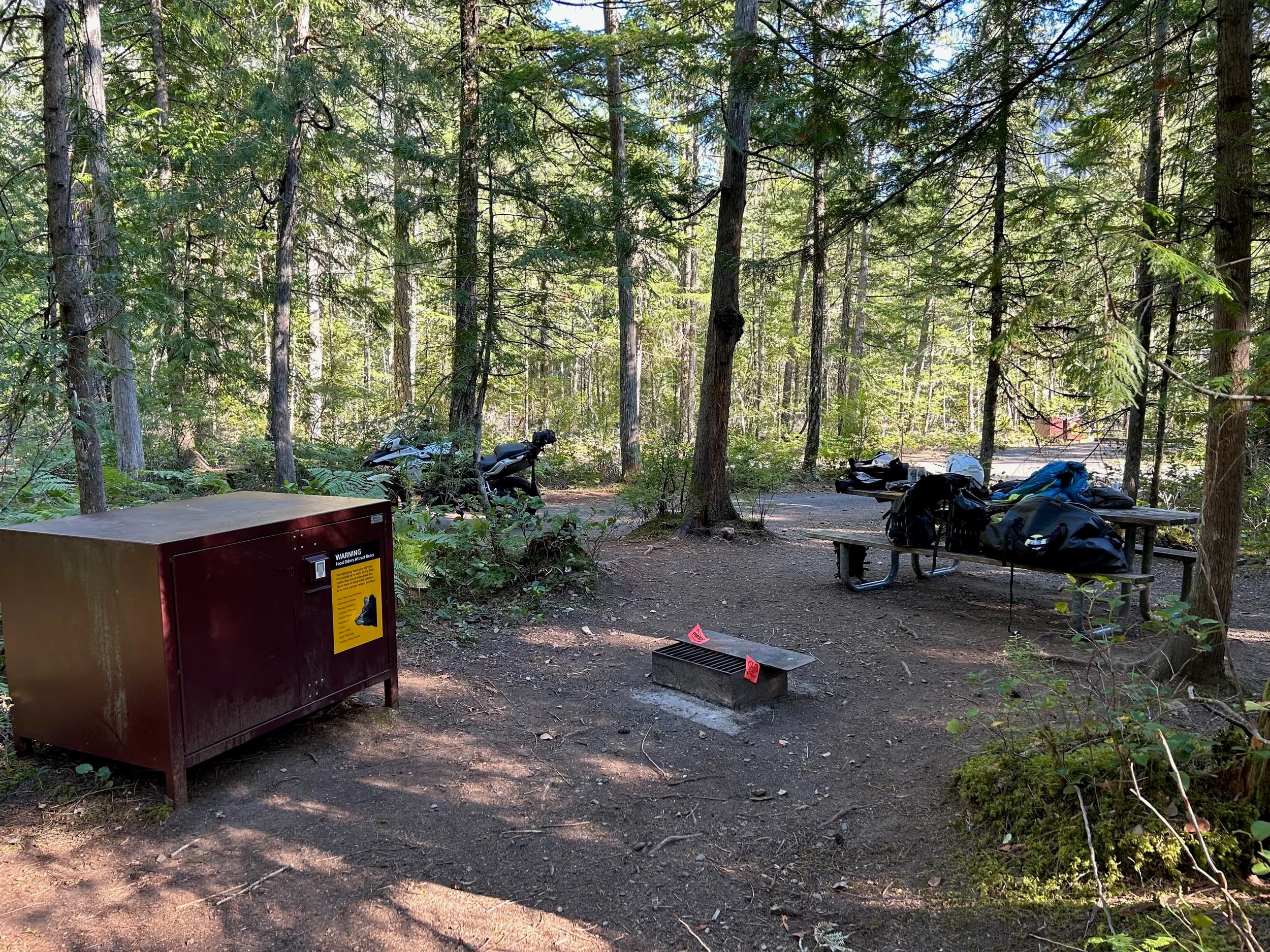 Trip Report: NW National Parks Loop
I left my job recently to take a much needed sabbatical and figure out what I’m doing next. A few weeks after my last day at work I embarked on what was to be a three week tour of NW-ish National Parks from Portland, to include Olympic, North Cascades, Glacier, Yellowstone, Grand Teton, Craters of the Moon, Lassen Volcanic, and Crater Lake.
I ended up missing Grand Tetons due to weather and I had to cut the trip short before I got to Lassen (family medical issue), so Lassen and Crater Lake remain unvisited.
Trip Dates: Sept 3 - Sept 16 (13 days)
Total Travel Miles: 3478 (does not include local miles for store runs, etc.)
Total Gallons of Gas Used: 82
Equipment: 2021 Benelli TRK502X Gaia GPS & Google Maps running on Sonim XP8 rugged Android phoneButler Motorcycle Maps (paper maps of best M/C roads in the country) iPhone 14 (main camera) Akaso Brave 7 helmet-mounted adventure camera Spot X satellite communicator and tracker Wolfman Luggage WP waterproof tank bag and saddle bags (no longer available) Watershed Colorado dry bag duffel (across the pillion seat) Kriega US-5 Drypack (tail bag) Kriega 3L hydration backpack (strapped to duffel, not worn)Marmot Ajax 2 tent Nemo hydrophobic down sleeping bag (non-mummy)Helinox ultralight cot MSR WhisperLite International stove
(Purchased in 1991 for my first moto trip: Detroit, MI to San Diego and back on an XT250)Gossamer Gear Bare Boxer bear-proof food canisters (two - one in each saddle bag)
Day 1 - Olympic National Park Date: Tuesday 9/3/2024
Destination: South Beach Campground, Olympic National Park
Travel Time: 4h 24m
Miles: 213Notes:
Planned to head west to Astoria then north from there, but left later than expected so headed up I-5 to US 12. I’ve driven/ridden that stretch of I-5 hundreds of times (starting in 1993). It’s boring and I hate it.
South Beach CG is first-come-first-served. I didn’t have issue getting a site. There is a long, tight loop of sites along the coastline, but I chose one of the sites further back near the bathrooms due to wind concerns. The bathroom building provided a sort of wind shelter for my site.
I used the heated grips on this leg; it was pretty chilly along the coast in the Olympic Peninsula. I almost didn’t install them, thinking I was being paranoid about the cold. I ended up using them a lot.
Day 2 - Ferry to Seattle / Burien Date: Wednesday 9/4/2024
Destination: Friend’s house in Burien, WA
Travel Time: 7h 30m
Miles: 199
Notes:
Slept well (thanks to Advil PM). I’ve not been sleeping well for more than a year. I’m really hoping to reset my sleep patterns with this trip. A good night’s sleep is one of my great joys and I feel like I’ve been robbed of that pleasure.
Used my Aeropress this morning for the first time ever. I’m hooked.
Headed up along US 101 through Port Angeles and then down to the Southworth ferry terminal near Port Orchard. Ferried across to Fauntleroy, which is just a few miles north my friend’s house in Burien. I’m always surprised at how long it takes to get from the Olympic Peninsula to the east side of Puget Sound (Seattle, etc.). With the ferry crossing (I love ferries) it took seven and a half hours to go 200 miles.
Discovered at my first stop of the day (just up 101 at the Kalaloch Campground, stopped to refill water) that the battery is quite weak and won’t start the bike if you leave the ignition on for even two minutes without the motor running. This would become a theme for the next few days. Fortunately, I have a jumper box and a permanent jump harness wired to the battery so jump starts are a quick operation.
Had a good evening with old friends.
Day 3 - North Cascades via Mountain Loop RoadDate: Thursday 9/5/2024
Destination: Newhalem Campground, North Cascades National Park
Travel Time: 4h 30m
Miles: 146Notes:
Slept well, on the couch. No pills needed.
I realized yesterday that my summer riding gloves (Rev’It Dune) were a size (or two) too small. Rev’It gloves fit really tight and I feel like I can never get it quite right. And yet, I love them. So, I stopped at a Cycle Gear in Bellevue to pick up something summer weight (Dirt 3) that fit better. They’re better, but maybe still one size too small. Such is life.
From Bellevue, I rode north and took the Mountain Loop Hwy then on up north to North Cascades. It was a hot ride. Still summer.
A small section of the Mountain Loop Road is dirt/gravel, which I didn’t realize. No biggie. Was just surprised (clearly I didn’t study my maps closely enough). When riding solo on a bike that weighs over 500 lbs., I tend to avoid planning much off-pavement riding. That’s what my DR-Z is for.
Day 4 - Newport, Washington via Winthrop Date: Friday 9/6/2024
Destination: Golden Spur Motor Inn, Newport, Washington
Travel Time: 8h
Miles: 308
Notes:
Slept just ok, even with Advil PM.
Pretty ride through North Cascades National Park and Colville National Forest. Didn’t do any backroads or hikes. Discovered (new to me) the town of Winthrop. Stopped for coffee at Sheri’s and resupplied on freeze-dried food at Cascades Outdoor Store.
The town of Newport is almost nothing, but, inexplicably, there’s an amazing restaurant (Brownell’s Place). Had dinner and a few ciders. Met and chatted with the owner/chef (she’s great). Listened to some live music. Then back to the motel.
Day 5 - New Battery in Kalispell Date: Saturday 9/7/2024
Destination: West Glacier KOA, West Glacier, MT
Travel Time: 8h 7m
Miles: 293
Notes:
Slept well on motel bed (on sleeping bag, not in the sheets). Another hot one.
Discovered that the water pump seal leaks oil. A quick post in the TRK Facebook group revealed that this is a common problem on this bike, and and easy fix. It’s apparently just a bad o-ring.
Battery has been getting continuously worse, and now requires I jump start the bike about every other start. Google Maps to the rescue: directions to the Batteries Plus in Kalispell, please. They don’t have an Odyssey AGM in the right size; the Duracell will have to do. (It’s been great.)
I set up camp at the West Glacier KOA, which will be my base for a few days. KOAs are their own little world. Very strange. Not really my thing, but the on-site laundry was handy.
After setting up camp I opened a cider and used the iPad to book a vehicle reservation for the next day to ride Going to the Sun Road, which I really wanted to do.
Day 6 - Going to the Sun RoadDate: Sunday 9/8/2024
Destination: Local Ride: West Glacier, Going to the Sun Road, Saint Mary, East Glacier
Travel Time: 5h 35m
Miles: 142Notes:
Quick breakfast and gas up in West Glacier before entering Going to the Sun Road.
Going to the Sun Road was stunning. This was the first point in the trip where I had tingles and was giddy at what I was seeing.
Took a very short hike along Saint Mary Lake. Again, I was beside myself with the beauty.
Lunch at the general store in Kiowa.
The rest of the ride back after East Glacier was meh, but I just kept thinking about how amazing what I’d seen in the morning had been.
Dinner at the KOA. Tacos from a cart (ok / not great, and a very weird guacamole) and a few glasses of wine from another cart. I asked about the guac and it turns out they make it in a food processor. Come on, people.
Day 7 - Ride to BozemanDate: Monday 9/9/2024
Destination: Friend’s house in Bozeman, Montana
Travel Time: ~ 8h (Gaia crashed near the end of the trip, but before getting to Bozeman)
Miles: ~ 400Notes:
Slept poorly again. No pills this time. Took some photos of my soft luggage setup to answer some questions in the TRK502X Facebook group. The saddle bags are from Wolfman Luggage, but I don’t think they make this waterproof line anymore. I use a duffel dry bag from Watershed across the top. A heat shield protects the side bag from exhaust heat.
Hazy, smoky ride most of the way. Very windy in places. This is where I first really started to feel how underpowered the TRK502 is. Really struggled in places.
Developed an engine-speed-sensitive squeak or rattle. Sounds like when a heat shield vibrates in resonance with engine vibration. Discovered that it’s a missing crash bar mounting bolt allowing the crash bar to rub against the frame.
Also noticed that there’s a resonant oscillation at speed that feels like the chain going bad (like it’s stretching unevenly).
First of several nights at a friend’s house in Bozeman (which, it turns out, is a pretty cool town). And there’s a hot tub…
Day 8 - Bike Maintenance & Hyalite ReservoirDate: Tuesday 9/10/2024
Destination: Local Ride: Hyalite Reservoir
Travel Time: not recorded
Miles: not recordedNotes:
Woke up to a smoky sunrise. I had the best night’s sleep I’ve had in years. This is was the whole point of this trip: to untangle my burnout and reclaim sleep as one of my joys. I wrote about it in my journal when I woke up. I hope this wasn’t a fluke.
Planned to replace the bolt that rattled loose from the crash bar, but instead discovered that it had actually severed off at the mount point. No fixing that on the road. Adjusted chain and moved on.
Lunch at Mountains Walking Brewery in Bozeman.
Rode up to Hyalite Reservoir. Pretty ride. Smoky still.
Soaked in hot tub after dinner.
Day 9 - North Yellowstone LoopDate: Wednesday 9/11/2024
Destination: Northern loop through Yellowstone National Park
Travel Time: 9h 36m
Miles: 272Notes:
Did a day trip from Bozeman down through the northern loop in Yellowstone, entering at Mammoth and taking the scenic route through Paradise Valley.
Saw elk, coyotes (I think), buffalo, and pronghorn.
Pretty ride, but cold in places. Used heated grips again.
Rode the loop through Mammoth Hot Springs (see video) at the end.
Coffee at Tumbleweed Bookstore & Cafe in Gardiner. I kind of dig Gardiner. Good vibe.
Had dinner at Mountains Walking Brewing. Rain and wind started. Lights flickered. Waited for rain to stop before riding back to the house.
Power out at the house due to high winds. This does not bode well for tomorrow.
Day 10 - Winter Weather in the ParksDate: Thursday 9/12/2024
Destination: Grand Teton National Park via West Yellowstone Pocatello, Idaho
Travel Time: 5h 40m
Miles: 201Notes:
Today was supposed to be a gorgeous ride through Yellowstone into Grand Teton National Park, and camping at Signal Mountain CG in the park. The weather had other ideas. It was pouring rain (and cold) all the way to West Yellowstone from Bozeman. By the time I got to West Yellowstone I was getting severe winter weather warnings on my phone calling for up to 3 (three!!) inches of snow accumulating in the high passes in the park. It’s bad enough in a car, but that’s a disaster waiting to happen on a motorcycle.
I parked my butt at Mountain Mama’s Cafe in West Yellowstone to warm up / dry off and decide what to do. I almost had myself convinced to push through when I realized that, even if I made it to the campground ok, I’d be setting up camp in the rain and I’d likely be miserable all night. Grand Teton would have to wait.
From West Yellowstone it’s easy to bail west into Idaho and get away from the park weather and elevations. So that’s what I did. It was not a pleasant ride, though. I was in torrential downpours all the way to Idaho Falls.
Arriving in Idaho Falls, I was exhausted and sure I could just find a room for the night. I dropped the bike at a roundabout (short-legged it coming to a stop; I knew it was going so I just rolled away). Guy behind me helped me pick it up. Then, there were no rooms because it was move in week for the two universities there (U of I, ISU). This would become a recurring theme.
I rode further to Blackfoot. Still no rooms.
I called ahead to Pocatello and got a room at a Red Lion there. I was never so happy to be off the bike.
No pictures this day. I couldn’t even get the action camera to turn on.
Day 11 - Craters of the Moon and EBR-1Date: Friday 9/13/2024
Destination: Craters of the Moon National Monument
Travel Time: 4h 20m
Miles: 124
Notes:
I wasn’t sure what my destination would be today but my plan was to do a little nuclear tourism, see Craters of the Moon, and then go somewhere from there. My schedule and day-plan was thrown off by missing Grand Teton National Park and spending a night in Pocatello, which was not on the itinerary at all.
Stopped in Atomic City. Not sure why; I was under the impression that Atomic City was the first city lit by nuclear engergy, but it was practically a ghost town. There are a few houses there, but as far as I could tell all of the business were shuttered. Except, maybe, for the race track; that looked like it might still get used.
Arco, it turns out, is the city celebrated as the first in the world to be lit by nuclear energy. Nothing special about the town, but they do a nice job of making City Hall photo-worthy.
Between Atomic City and Arco is EBR-1 (Experimental Breeder Reactor I) which was the world’s first breeder reactor. The EBR-1 exhibit was closed for the season, but in the lot next to it were some really interesting experimental nuclear heat-transfer jet engines that never made it out of the experimental phase (probably a good thing).
Craters of the Moon is pretty small. If you don’t do any of the walks, it’s literally just a 30 minute road loop. Still, it was an unexpected surprise and delight. I had no idea what to expect but I was positively chuffed at the experience. I noticed that the campground had open sites so I inquired at the entry booth. As luck would have it, the whole campground is first come / first serve. I decided to set up for the night. It’s good to be done early and have some time to read and not stress about making distance.
Day 12 - New Chain in Twin FallsDate: Saturday 9/14/2024
Destination: Battle Mountain, Nevada
Travel Time: 8h 52m
Miles: 335
Notes:
Beautiful morning in Craters of the Moon. While I was breaking camp a parade of classic cars came into the park to drive the loop. I got a picture of one Pontiac down the road in Carey at a gas station.
Carey ended up being an unplanned fork in the road for me. I discovered this morning that my chain was indeed stretching unevenly, and the oscillation I was feeling and hearing was the chain hum changing from a “loose” hum to a “tight” hum rapidly as the tight spot moved around the sprockets. I was supposed to continue west to Mountain Home and then south from there into Nevada. A very scenic route, according to my Butler map. But, between camp and the gas station I got pretty paranoid about the chain snapping at high speed, which, worst case, could lead to a fatal crash.
So I called ahead to a few motorcycle dealers in Mountain Home (on my planned route) to see if they could take me in and replace the chain. No dice. This is the downside of having an obscure motorcycle from an obscure marque - no one wants to work on it. Making matters worse this is an Italian-designed bike built in China, a fact which causes many people to lose the ability to think clearly. “It’s Chinese junk!” Not so. Next.
With Mountain Home out, I tried Twin Falls. My first call was to Adventure Motorsports, and the service manager there took me in with no hesitation. “How soon can you be here?” I didn’t get his name, but my hat’s off to him and his one tech working furiously on a Saturday to beat the 3pm closing time. He said during high season, they get about 15-20 out of town travelers per week who need something done, and they take them all in. I love to hear stuff like this. This shop is in it for the community. They have a nice showroom, too.
With a quality new chain installed, I got a burrito and a MexiCoke at a Mexican place and went on my way. I made it to Battle Mountain, NV, where I decide to get a room. Tomorrow I rejoin my planned scenic route. Day 13 - Desert Mountains in NV, CADate: Sunday 9/15/2024
Destination: Grizzly Campground, Lake Davis (near Portola, CA)
Travel Time: 7h
Miles: 307
Notes:
I love the northern Nevada landscape, and today’s ride didn’t disappoint. US Highway 50 is apparently known as “The Loneliest Highway” but everyone knows about it, so it’s not very lonely. However, after leaving Austin, NV headed west you can take Nevada Highway 722, which dips to the south and follows the old US 50 route. It was completely empty and the twisties through the passes were fun. Highly recommended.
Stopped in Fallon for gas and to find a Micro SD card for the action camera. Walmart to the rescue.
After Reno, I crossed into California and, I swear, it looks different. Norther California desert mountains are so beautiful.
Camped at a nearly empty campground on Lake Davis (very end of the season). The host warned me rain was coming tomorrow.
Day 14 - Unplanned Return HomeDate: Monday 9/16/2024
Destination: Summit Lake Campground, Lassen Volcanic National Park Portland, Oregon (Home)
Travel Time: 10h 32m
Miles: 538Notes:
Last week, my mom went into the hospital for a fairly routine procedure. My brother went to Michigan to help out, as needed, and he went back home to Arizona after she returned home and everything seemed settled.
This morning, while having coffee, I got a call that she’d gone back into the hospital with something that may or may not have been related to the procedure. It seemed like maybe things were ok, but maybe not.
I decided the best thing to do was head home so that I was near an airport if I needed to fly out to Michigan to help out.
I packed up camp and headed up US 395 toward home, via Klamath Falls. It was a pretty ride, but, once again, I found myself in rain most of the way to Klamath Falls.
I was pretty beat by the time I got to Klamath Falls and figured I’d just find a hotel room, get a hot shower, and finish the ride tomorrow.
But, once again, it was move-in week for the local university. Holiday Inn Express had a single room for $395. No thanks. Onward.
I never hit rain again after Klamath Falls, and after turning west onto Oregon Hwy 58 and starting to lose elevation into the Willamette Valley, the temperature starting rising, which was welcome.
Once I reached Eugene, there was no point in not just going all the way home, so that’s what I did.
I got two pictures: one at camp before the call, and one at my last gas stop, an hour and twenty minutes from home, with the moon rising.
A nice side effect of my early return home is that I was home for my birthday (tomorrow), so I had dinner with my kids and my wife, which was lovely.
I did end up flying to Michigan the next day, and was there for a bit. The best part? I got to make some meals for my mom and step dad. Everything seems ok with my mom for now.
Grand Teton, Lassen, and Crater Lake will be there, and now I have an excuse for another trip in the future.