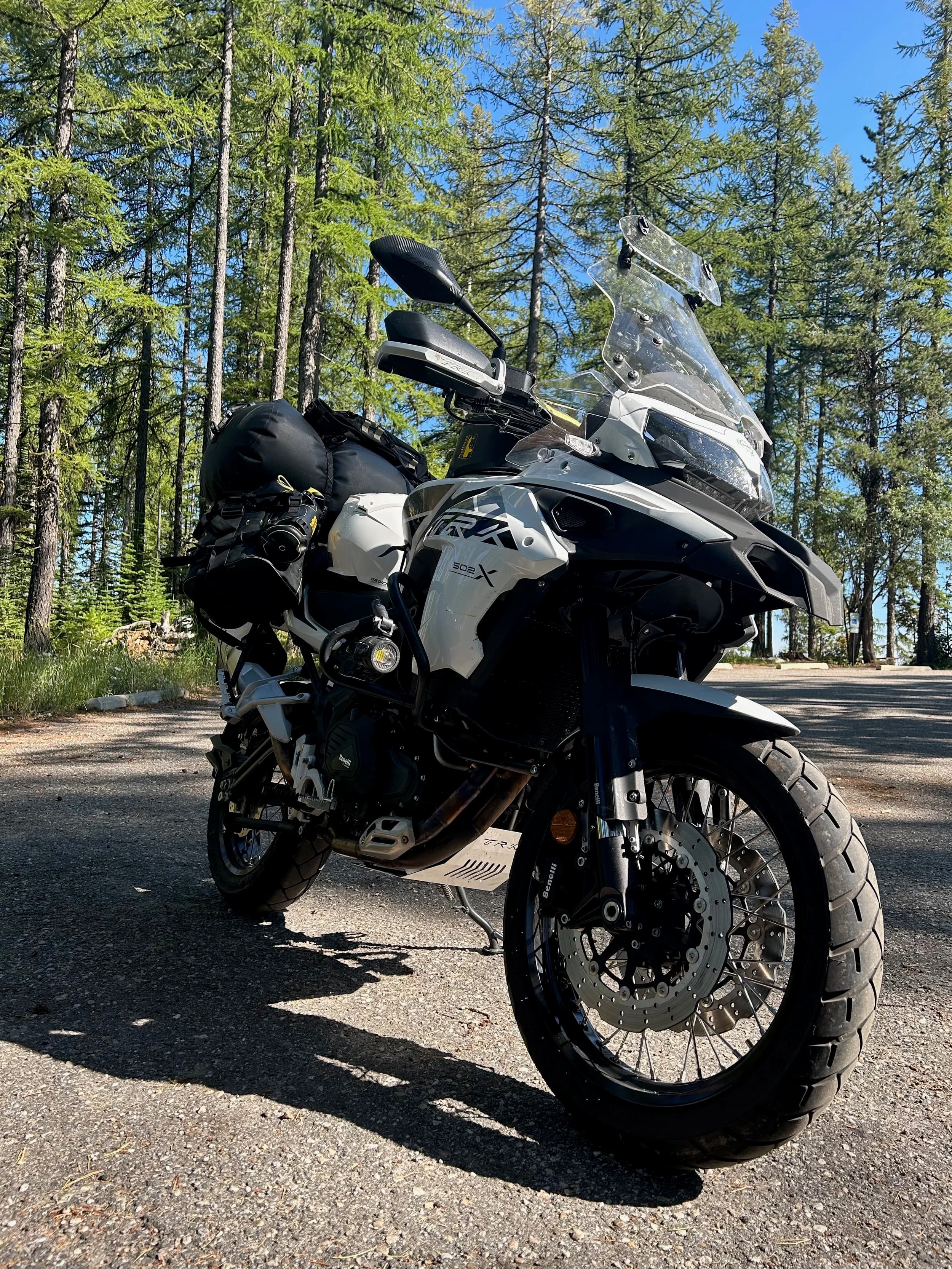 Trip Report: NW National Parks Loop
I left my job recently to take a much needed sabbatical and figure out what I’m doing next. A few weeks after my last day at work I embarked on what was to be a three week tour of NW-ish National Parks from Portland, to include Olympic, North Cascades, Glacier, Yellowstone, Grand Teton, Craters of the Moon, Lassen Volcanic, and Crater Lake.
I ended up missing Grand Tetons due to weather and I had to cut the trip short before I got to Lassen (family medical issue), so Lassen and Crater Lake remain unvisited.
Trip Dates: Sept 3 - Sept 16 (13 days)
Total Travel Miles: 3478 (does not include local miles for store runs, etc.)
Total Gallons of Gas Used: 82
Equipment: 2021 Benelli TRK502X Gaia GPS & Google Maps running on Sonim XP8 rugged Android phoneButler Motorcycle Maps (paper maps of best M/C roads in the country) iPhone 14 (main camera) Akaso Brave 7 helmet-mounted adventure camera Spot X satellite communicator and tracker Wolfman Luggage WP waterproof tank bag and saddle bags (no longer available) Watershed Colorado dry bag duffel (across the pillion seat) Kriega US-5 Drypack (tail bag) Kriega 3L hydration backpack (strapped to duffel, not worn)Marmot Ajax 2 tent Nemo hydrophobic down sleeping bag (non-mummy)Helinox ultralight cot MSR WhisperLite International stove
(Purchased in 1991 for my first moto trip: Detroit, MI to San Diego and back on an XT250)Gossamer Gear Bare Boxer bear-proof food canisters (two - one in each saddle bag)
Day 1 - Olympic National Park Date: Tuesday 9/3/2024
Destination: South Beach Campground, Olympic National Park
Travel Time: 4h 24m
Miles: 213Notes:
Planned to head west to Astoria then north from there, but left later than expected so headed up I-5 to US 12. I’ve driven/ridden that stretch of I-5 hundreds of times (starting in 1993). It’s boring and I hate it.
South Beach CG is first-come-first-served. I didn’t have issue getting a site. There is a long, tight loop of sites along the coastline, but I chose one of the sites further back near the bathrooms due to wind concerns. The bathroom building provided a sort of wind shelter for my site.
I used the heated grips on this leg; it was pretty chilly along the coast in the Olympic Peninsula. I almost didn’t install them, thinking I was being paranoid about the cold. I ended up using them a lot.
Day 2 - Ferry to Seattle / Burien Date: Wednesday 9/4/2024
Destination: Friend’s house in Burien, WA
Travel Time: 7h 30m
Miles: 199
Notes:
Slept well (thanks to Advil PM). I’ve not been sleeping well for more than a year. I’m really hoping to reset my sleep patterns with this trip. A good night’s sleep is one of my great joys and I feel like I’ve been robbed of that pleasure.
Used my Aeropress this morning for the first time ever. I’m hooked.
Headed up along US 101 through Port Angeles and then down to the Southworth ferry terminal near Port Orchard. Ferried across to Fauntleroy, which is just a few miles north my friend’s house in Burien. I’m always surprised at how long it takes to get from the Olympic Peninsula to the east side of Puget Sound (Seattle, etc.). With the ferry crossing (I love ferries) it took seven and a half hours to go 200 miles.
Discovered at my first stop of the day (just up 101 at the Kalaloch Campground, stopped to refill water) that the battery is quite weak and won’t start the bike if you leave the ignition on for even two minutes without the motor running. This would become a theme for the next few days. Fortunately, I have a jumper box and a permanent jump harness wired to the battery so jump starts are a quick operation.
Had a good evening with old friends.
Day 3 - North Cascades via Mountain Loop RoadDate: Thursday 9/5/2024
Destination: Newhalem Campground, North Cascades National Park
Travel Time: 4h 30m
Miles: 146Notes:
Slept well, on the couch. No pills needed.
I realized yesterday that my summer riding gloves (Rev’It Dune) were a size (or two) too small. Rev’It gloves fit really tight and I feel like I can never get it quite right. And yet, I love them. So, I stopped at a Cycle Gear in Bellevue to pick up something summer weight (Dirt 3) that fit better. They’re better, but maybe still one size too small. Such is life.
From Bellevue, I rode north and took the Mountain Loop Hwy then on up north to North Cascades. It was a hot ride. Still summer.
A small section of the Mountain Loop Road is dirt/gravel, which I didn’t realize. No biggie. Was just surprised (clearly I didn’t study my maps closely enough). When riding solo on a bike that weighs over 500 lbs., I tend to avoid planning much off-pavement riding. That’s what my DR-Z is for.
Day 4 - Newport, Washington via Winthrop Date: Friday 9/6/2024
Destination: Golden Spur Motor Inn, Newport, Washington
Travel Time: 8h
Miles: 308
Notes:
Slept just ok, even with Advil PM.
Pretty ride through North Cascades National Park and Colville National Forest. Didn’t do any backroads or hikes. Discovered (new to me) the town of Winthrop. Stopped for coffee at Sheri’s and resupplied on freeze-dried food at Cascades Outdoor Store.
The town of Newport is almost nothing, but, inexplicably, there’s an amazing restaurant (Brownell’s Place). Had dinner and a few ciders. Met and chatted with the owner/chef (she’s great). Listened to some live music. Then back to the motel.
Day 5 - New Battery in Kalispell Date: Saturday 9/7/2024
Destination: West Glacier KOA, West Glacier, MT
Travel Time: 8h 7m
Miles: 293
Notes:
Slept well on motel bed (on sleeping bag, not in the sheets). Another hot one.
Discovered that the water pump seal leaks oil. A quick post in the TRK Facebook group revealed that this is a common problem on this bike, and and easy fix. It’s apparently just a bad o-ring.
Battery has been getting continuously worse, and now requires I jump start the bike about every other start. Google Maps to the rescue: directions to the Batteries Plus in Kalispell, please. They don’t have an Odyssey AGM in the right size; the Duracell will have to do. (It’s been great.)
I set up camp at the West Glacier KOA, which will be my base for a few days. KOAs are their own little world. Very strange. Not really my thing, but the on-site laundry was handy.
After setting up camp I opened a cider and used the iPad to book a vehicle reservation for the next day to ride Going to the Sun Road, which I really wanted to do.
Day 6 - Going to the Sun RoadDate: Sunday 9/8/2024
Destination: Local Ride: West Glacier, Going to the Sun Road, Saint Mary, East Glacier
Travel Time: 5h 35m
Miles: 142Notes:
Quick breakfast and gas up in West Glacier before entering Going to the Sun Road.
Going to the Sun Road was stunning. This was the first point in the trip where I had tingles and was giddy at what I was seeing.
Took a very short hike along Saint Mary Lake. Again, I was beside myself with the beauty.
Lunch at the general store in Kiowa.
The rest of the ride back after East Glacier was meh, but I just kept thinking about how amazing what I’d seen in the morning had been.
Dinner at the KOA. Tacos from a cart (ok / not great, and a very weird guacamole) and a few glasses of wine from another cart. I asked about the guac and it turns out they make it in a food processor. Come on, people.
Day 7 - Ride to BozemanDate: Monday 9/9/2024
Destination: Friend’s house in Bozeman, Montana
Travel Time: ~ 8h (Gaia crashed near the end of the trip, but before getting to Bozeman)
Miles: ~ 400Notes:
Slept poorly again. No pills this time. Took some photos of my soft luggage setup to answer some questions in the TRK502X Facebook group. The saddle bags are from Wolfman Luggage, but I don’t think they make this waterproof line anymore. I use a duffel dry bag from Watershed across the top. A heat shield protects the side bag from exhaust heat.
Hazy, smoky ride most of the way. Very windy in places. This is where I first really started to feel how underpowered the TRK502 is. Really struggled in places.
Developed an engine-speed-sensitive squeak or rattle. Sounds like when a heat shield vibrates in resonance with engine vibration. Discovered that it’s a missing crash bar mounting bolt allowing the crash bar to rub against the frame.
Also noticed that there’s a resonant oscillation at speed that feels like the chain going bad (like it’s stretching unevenly).
First of several nights at a friend’s house in Bozeman (which, it turns out, is a pretty cool town). And there’s a hot tub…
Day 8 - Bike Maintenance & Hyalite ReservoirDate: Tuesday 9/10/2024
Destination: Local Ride: Hyalite Reservoir
Travel Time: not recorded
Miles: not recordedNotes:
Woke up to a smoky sunrise. I had the best night’s sleep I’ve had in years. This is was the whole point of this trip: to untangle my burnout and reclaim sleep as one of my joys. I wrote about it in my journal when I woke up. I hope this wasn’t a fluke.
Planned to replace the bolt that rattled loose from the crash bar, but instead discovered that it had actually severed off at the mount point. No fixing that on the road. Adjusted chain and moved on.
Lunch at Mountains Walking Brewery in Bozeman.
Rode up to Hyalite Reservoir. Pretty ride. Smoky still.
Soaked in hot tub after dinner.
Day 9 - North Yellowstone LoopDate: Wednesday 9/11/2024
Destination: Northern loop through Yellowstone National Park
Travel Time: 9h 36m
Miles: 272Notes:
Did a day trip from Bozeman down through the northern loop in Yellowstone, entering at Mammoth and taking the scenic route through Paradise Valley.
Saw elk, coyotes (I think), buffalo, and pronghorn.
Pretty ride, but cold in places. Used heated grips again.
Rode the loop through Mammoth Hot Springs (see video) at the end.
Coffee at Tumbleweed Bookstore & Cafe in Gardiner. I kind of dig Gardiner. Good vibe.
Had dinner at Mountains Walking Brewing. Rain and wind started. Lights flickered. Waited for rain to stop before riding back to the house.
Power out at the house due to high winds. This does not bode well for tomorrow.
Day 10 - Winter Weather in the ParksDate: Thursday 9/12/2024
Destination: Grand Teton National Park via West Yellowstone Pocatello, Idaho
Travel Time: 5h 40m
Miles: 201Notes:
Today was supposed to be a gorgeous ride through Yellowstone into Grand Teton National Park, and camping at Signal Mountain CG in the park. The weather had other ideas. It was pouring rain (and cold) all the way to West Yellowstone from Bozeman. By the time I got to West Yellowstone I was getting severe winter weather warnings on my phone calling for up to 3 (three!!) inches of snow accumulating in the high passes in the park. It’s bad enough in a car, but that’s a disaster waiting to happen on a motorcycle.
I parked my butt at Mountain Mama’s Cafe in West Yellowstone to warm up / dry off and decide what to do. I almost had myself convinced to push through when I realized that, even if I made it to the campground ok, I’d be setting up camp in the rain and I’d likely be miserable all night. Grand Teton would have to wait.
From West Yellowstone it’s easy to bail west into Idaho and get away from the park weather and elevations. So that’s what I did. It was not a pleasant ride, though. I was in torrential downpours all the way to Idaho Falls.
Arriving in Idaho Falls, I was exhausted and sure I could just find a room for the night. I dropped the bike at a roundabout (short-legged it coming to a stop; I knew it was going so I just rolled away). Guy behind me helped me pick it up. Then, there were no rooms because it was move in week for the two universities there (U of I, ISU). This would become a recurring theme.
I rode further to Blackfoot. Still no rooms.
I called ahead to Pocatello and got a room at a Red Lion there. I was never so happy to be off the bike.
No pictures this day. I couldn’t even get the action camera to turn on.
Day 11 - Craters of the Moon and EBR-1Date: Friday 9/13/2024
Destination: Craters of the Moon National Monument
Travel Time: 4h 20m
Miles: 124
Notes:
I wasn’t sure what my destination would be today but my plan was to do a little nuclear tourism, see Craters of the Moon, and then go somewhere from there. My schedule and day-plan was thrown off by missing Grand Teton National Park and spending a night in Pocatello, which was not on the itinerary at all.
Stopped in Atomic City. Not sure why; I was under the impression that Atomic City was the first city lit by nuclear engergy, but it was practically a ghost town. There are a few houses there, but as far as I could tell all of the business were shuttered. Except, maybe, for the race track; that looked like it might still get used.
Arco, it turns out, is the city celebrated as the first in the world to be lit by nuclear energy. Nothing special about the town, but they do a nice job of making City Hall photo-worthy.
Between Atomic City and Arco is EBR-1 (Experimental Breeder Reactor I) which was the world’s first breeder reactor. The EBR-1 exhibit was closed for the season, but in the lot next to it were some really interesting experimental nuclear heat-transfer jet engines that never made it out of the experimental phase (probably a good thing).
Craters of the Moon is pretty small. If you don’t do any of the walks, it’s literally just a 30 minute road loop. Still, it was an unexpected surprise and delight. I had no idea what to expect but I was positively chuffed at the experience. I noticed that the campground had open sites so I inquired at the entry booth. As luck would have it, the whole campground is first come / first serve. I decided to set up for the night. It’s good to be done early and have some time to read and not stress about making distance.
Day 12 - New Chain in Twin FallsDate: Saturday 9/14/2024
Destination: Battle Mountain, Nevada
Travel Time: 8h 52m
Miles: 335
Notes:
Beautiful morning in Craters of the Moon. While I was breaking camp a parade of classic cars came into the park to drive the loop. I got a picture of one Pontiac down the road in Carey at a gas station.
Carey ended up being an unplanned fork in the road for me. I discovered this morning that my chain was indeed stretching unevenly, and the oscillation I was feeling and hearing was the chain hum changing from a “loose” hum to a “tight” hum rapidly as the tight spot moved around the sprockets. I was supposed to continue west to Mountain Home and then south from there into Nevada. A very scenic route, according to my Butler map. But, between camp and the gas station I got pretty paranoid about the chain snapping at high speed, which, worst case, could lead to a fatal crash.
So I called ahead to a few motorcycle dealers in Mountain Home (on my planned route) to see if they could take me in and replace the chain. No dice. This is the downside of having an obscure motorcycle from an obscure marque - no one wants to work on it. Making matters worse this is an Italian-designed bike built in China, a fact which causes many people to lose the ability to think clearly. “It’s Chinese junk!” Not so. Next.
With Mountain Home out, I tried Twin Falls. My first call was to Adventure Motorsports, and the service manager there took me in with no hesitation. “How soon can you be here?” I didn’t get his name, but my hat’s off to him and his one tech working furiously on a Saturday to beat the 3pm closing time. He said during high season, they get about 15-20 out of town travelers per week who need something done, and they take them all in. I love to hear stuff like this. This shop is in it for the community. They have a nice showroom, too.
With a quality new chain installed, I got a burrito and a MexiCoke at a Mexican place and went on my way. I made it to Battle Mountain, NV, where I decide to get a room. Tomorrow I rejoin my planned scenic route. Day 13 - Desert Mountains in NV, CADate: Sunday 9/15/2024
Destination: Grizzly Campground, Lake Davis (near Portola, CA)
Travel Time: 7h
Miles: 307
Notes:
I love the northern Nevada landscape, and today’s ride didn’t disappoint. US Highway 50 is apparently known as “The Loneliest Highway” but everyone knows about it, so it’s not very lonely. However, after leaving Austin, NV headed west you can take Nevada Highway 722, which dips to the south and follows the old US 50 route. It was completely empty and the twisties through the passes were fun. Highly recommended.
Stopped in Fallon for gas and to find a Micro SD card for the action camera. Walmart to the rescue.
After Reno, I crossed into California and, I swear, it looks different. Norther California desert mountains are so beautiful.
Camped at a nearly empty campground on Lake Davis (very end of the season). The host warned me rain was coming tomorrow.
Day 14 - Unplanned Return HomeDate: Monday 9/16/2024
Destination: Summit Lake Campground, Lassen Volcanic National Park Portland, Oregon (Home)
Travel Time: 10h 32m
Miles: 538Notes:
Last week, my mom went into the hospital for a fairly routine procedure. My brother went to Michigan to help out, as needed, and he went back home to Arizona after she returned home and everything seemed settled.
This morning, while having coffee, I got a call that she’d gone back into the hospital with something that may or may not have been related to the procedure. It seemed like maybe things were ok, but maybe not.
I decided the best thing to do was head home so that I was near an airport if I needed to fly out to Michigan to help out.
I packed up camp and headed up US 395 toward home, via Klamath Falls. It was a pretty ride, but, once again, I found myself in rain most of the way to Klamath Falls.
I was pretty beat by the time I got to Klamath Falls and figured I’d just find a hotel room, get a hot shower, and finish the ride tomorrow.
But, once again, it was move-in week for the local university. Holiday Inn Express had a single room for $395. No thanks. Onward.
I never hit rain again after Klamath Falls, and after turning west onto Oregon Hwy 58 and starting to lose elevation into the Willamette Valley, the temperature starting rising, which was welcome.
Once I reached Eugene, there was no point in not just going all the way home, so that’s what I did.
I got two pictures: one at camp before the call, and one at my last gas stop, an hour and twenty minutes from home, with the moon rising.
A nice side effect of my early return home is that I was home for my birthday (tomorrow), so I had dinner with my kids and my wife, which was lovely.
I did end up flying to Michigan the next day, and was there for a bit. The best part? I got to make some meals for my mom and step dad. Everything seems ok with my mom for now.
Grand Teton, Lassen, and Crater Lake will be there, and now I have an excuse for another trip in the future.
