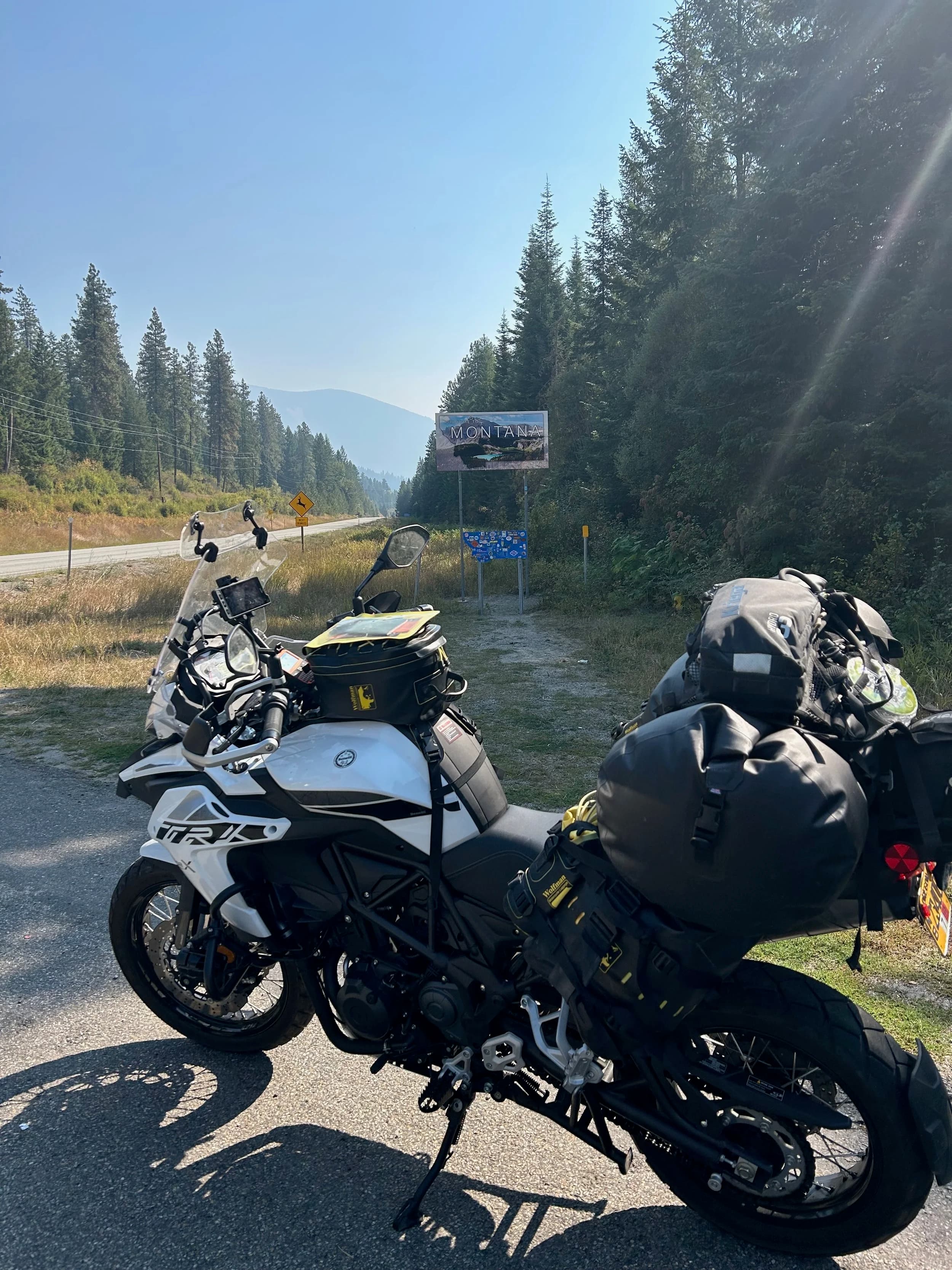 Trip Report: NW National Parks Loop
I left my job recently to take a much needed sabbatical and figure out what I’m doing next. A few weeks after my last day at work I embarked on what was to be a three week tour of NW-ish National Parks from Portland, to include Olympic, North Cascades, Glacier, Yellowstone, Grand Teton, Craters of the Moon, Lassen Volcanic, and Crater Lake.
I ended up missing Grand Tetons due to weather and I had to cut the trip short before I got to Lassen (family medical issue), so Lassen and Crater Lake remain unvisited.
Trip Dates: Sept 3 - Sept 16 (13 days)
Total Travel Miles: 3478 (does not include local miles for store runs, etc.)
Total Gallons of Gas Used: 82
Equipment: 2021 Benelli TRK502X Gaia GPS & Google Maps running on Sonim XP8 rugged Android phoneButler Motorcycle Maps (paper maps of best M/C roads in the country) iPhone 14 (main camera) Akaso Brave 7 helmet-mounted adventure camera Spot X satellite communicator and tracker Wolfman Luggage WP waterproof tank bag and saddle bags (no longer available) Watershed Colorado dry bag duffel (across the pillion seat) Kriega US-5 Drypack (tail bag) Kriega 3L hydration backpack (strapped to duffel, not worn)Marmot Ajax 2 tent Nemo hydrophobic down sleeping bag (non-mummy)Helinox ultralight cot MSR WhisperLite International stove
(Purchased in 1991 for my first moto trip: Detroit, MI to San Diego and back on an XT250)Gossamer Gear Bare Boxer bear-proof food canisters (two - one in each saddle bag)
Day 1 - Olympic National Park Date: Tuesday 9/3/2024
Destination: South Beach Campground, Olympic National Park
Travel Time: 4h 24m
Miles: 213Notes:
Planned to head west to Astoria then north from there, but left later than expected so headed up I-5 to US 12. I’ve driven/ridden that stretch of I-5 hundreds of times (starting in 1993). It’s boring and I hate it.
South Beach CG is first-come-first-served. I didn’t have issue getting a site. There is a long, tight loop of sites along the coastline, but I chose one of the sites further back near the bathrooms due to wind concerns. The bathroom building provided a sort of wind shelter for my site.
I used the heated grips on this leg; it was pretty chilly along the coast in the Olympic Peninsula. I almost didn’t install them, thinking I was being paranoid about the cold. I ended up using them a lot.
Day 2 - Ferry to Seattle / Burien Date: Wednesday 9/4/2024
Destination: Friend’s house in Burien, WA
Travel Time: 7h 30m
Miles: 199
Notes:
Slept well (thanks to Advil PM). I’ve not been sleeping well for more than a year. I’m really hoping to reset my sleep patterns with this trip. A good night’s sleep is one of my great joys and I feel like I’ve been robbed of that pleasure.
Used my Aeropress this morning for the first time ever. I’m hooked.
Headed up along US 101 through Port Angeles and then down to the Southworth ferry terminal near Port Orchard. Ferried across to Fauntleroy, which is just a few miles north my friend’s house in Burien. I’m always surprised at how long it takes to get from the Olympic Peninsula to the east side of Puget Sound (Seattle, etc.). With the ferry crossing (I love ferries) it took seven and a half hours to go 200 miles.
Discovered at my first stop of the day (just up 101 at the Kalaloch Campground, stopped to refill water) that the battery is quite weak and won’t start the bike if you leave the ignition on for even two minutes without the motor running. This would become a theme for the next few days. Fortunately, I have a jumper box and a permanent jump harness wired to the battery so jump starts are a quick operation.
Had a good evening with old friends.
Day 3 - North Cascades via Mountain Loop RoadDate: Thursday 9/5/2024
Destination: Newhalem Campground, North Cascades National Park
Travel Time: 4h 30m
Miles: 146Notes:
Slept well, on the couch. No pills needed.
I realized yesterday that my summer riding gloves (Rev’It Dune) were a size (or two) too small. Rev’It gloves fit really tight and I feel like I can never get it quite right. And yet, I love them. So, I stopped at a Cycle Gear in Bellevue to pick up something summer weight (Dirt 3) that fit better. They’re better, but maybe still one size too small. Such is life.
From Bellevue, I rode north and took the Mountain Loop Hwy then on up north to North Cascades. It was a hot ride. Still summer.
A small section of the Mountain Loop Road is dirt/gravel, which I didn’t realize. No biggie. Was just surprised (clearly I didn’t study my maps closely enough). When riding solo on a bike that weighs over 500 lbs., I tend to avoid planning much off-pavement riding. That’s what my DR-Z is for.
Day 4 - Newport, Washington via Winthrop Date: Friday 9/6/2024
Destination: Golden Spur Motor Inn, Newport, Washington
Travel Time: 8h
Miles: 308
Notes:
Slept just ok, even with Advil PM.
Pretty ride through North Cascades National Park and Colville National Forest. Didn’t do any backroads or hikes. Discovered (new to me) the town of Winthrop. Stopped for coffee at Sheri’s and resupplied on freeze-dried food at Cascades Outdoor Store.
The town of Newport is almost nothing, but, inexplicably, there’s an amazing restaurant (Brownell’s Place). Had dinner and a few ciders. Met and chatted with the owner/chef (she’s great). Listened to some live music. Then back to the motel.
Day 5 - New Battery in Kalispell Date: Saturday 9/7/2024
Destination: West Glacier KOA, West Glacier, MT
Travel Time: 8h 7m
Miles: 293
Notes:
Slept well on motel bed (on sleeping bag, not in the sheets). Another hot one.
Discovered that the water pump seal leaks oil. A quick post in the TRK Facebook group revealed that this is a common problem on this bike, and and easy fix. It’s apparently just a bad o-ring.
Battery has been getting continuously worse, and now requires I jump start the bike about every other start. Google Maps to the rescue: directions to the Batteries Plus in Kalispell, please. They don’t have an Odyssey AGM in the right size; the Duracell will have to do. (It’s been great.)
I set up camp at the West Glacier KOA, which will be my base for a few days. KOAs are their own little world. Very strange. Not really my thing, but the on-site laundry was handy.
After setting up camp I opened a cider and used the iPad to book a vehicle reservation for the next day to ride Going to the Sun Road, which I really wanted to do.
Day 6 - Going to the Sun RoadDate: Sunday 9/8/2024
Destination: Local Ride: West Glacier, Going to the Sun Road, Saint Mary, East Glacier
Travel Time: 5h 35m
Miles: 142Notes:
Quick breakfast and gas up in West Glacier before entering Going to the Sun Road.
Going to the Sun Road was stunning. This was the first point in the trip where I had tingles and was giddy at what I was seeing.
Took a very short hike along Saint Mary Lake. Again, I was beside myself with the beauty.
Lunch at the general store in Kiowa.
The rest of the ride back after East Glacier was meh, but I just kept thinking about how amazing what I’d seen in the morning had been.
Dinner at the KOA. Tacos from a cart (ok / not great, and a very weird guacamole) and a few glasses of wine from another cart. I asked about the guac and it turns out they make it in a food processor. Come on, people.
Day 7 - Ride to BozemanDate: Monday 9/9/2024
Destination: Friend’s house in Bozeman, Montana
Travel Time: ~ 8h (Gaia crashed near the end of the trip, but before getting to Bozeman)
Miles: ~ 400Notes:
Slept poorly again. No pills this time. Took some photos of my soft luggage setup to answer some questions in the TRK502X Facebook group. The saddle bags are from Wolfman Luggage, but I don’t think they make this waterproof line anymore. I use a duffel dry bag from Watershed across the top. A heat shield protects the side bag from exhaust heat.
Hazy, smoky ride most of the way. Very windy in places. This is where I first really started to feel how underpowered the TRK502 is. Really struggled in places.
Developed an engine-speed-sensitive squeak or rattle. Sounds like when a heat shield vibrates in resonance with engine vibration. Discovered that it’s a missing crash bar mounting bolt allowing the crash bar to rub against the frame.
Also noticed that there’s a resonant oscillation at speed that feels like the chain going bad (like it’s stretching unevenly).
First of several nights at a friend’s house in Bozeman (which, it turns out, is a pretty cool town). And there’s a hot tub…
Day 8 - Bike Maintenance & Hyalite ReservoirDate: Tuesday 9/10/2024
Destination: Local Ride: Hyalite Reservoir
Travel Time: not recorded
Miles: not recordedNotes:
Woke up to a smoky sunrise. I had the best night’s sleep I’ve had in years. This is was the whole point of this trip: to untangle my burnout and reclaim sleep as one of my joys. I wrote about it in my journal when I woke up. I hope this wasn’t a fluke.
Planned to replace the bolt that rattled loose from the crash bar, but instead discovered that it had actually severed off at the mount point. No fixing that on the road. Adjusted chain and moved on.
Lunch at Mountains Walking Brewery in Bozeman.
Rode up to Hyalite Reservoir. Pretty ride. Smoky still.
Soaked in hot tub after dinner.
Day 9 - North Yellowstone LoopDate: Wednesday 9/11/2024
Destination: Northern loop through Yellowstone National Park
Travel Time: 9h 36m
Miles: 272Notes:
Did a day trip from Bozeman down through the northern loop in Yellowstone, entering at Mammoth and taking the scenic route through Paradise Valley.
Saw elk, coyotes (I think), buffalo, and pronghorn.
Pretty ride, but cold in places. Used heated grips again.
Rode the loop through Mammoth Hot Springs (see video) at the end.
Coffee at Tumbleweed Bookstore & Cafe in Gardiner. I kind of dig Gardiner. Good vibe.
Had dinner at Mountains Walking Brewing. Rain and wind started. Lights flickered. Waited for rain to stop before riding back to the house.
Power out at the house due to high winds. This does not bode well for tomorrow.
Day 10 - Winter Weather in the ParksDate: Thursday 9/12/2024
Destination: Grand Teton National Park via West Yellowstone Pocatello, Idaho
Travel Time: 5h 40m
Miles: 201Notes:
Today was supposed to be a gorgeous ride through Yellowstone into Grand Teton National Park, and camping at Signal Mountain CG in the park. The weather had other ideas. It was pouring rain (and cold) all the way to West Yellowstone from Bozeman. By the time I got to West Yellowstone I was getting severe winter weather warnings on my phone calling for up to 3 (three!!) inches of snow accumulating in the high passes in the park. It’s bad enough in a car, but that’s a disaster waiting to happen on a motorcycle.
I parked my butt at Mountain Mama’s Cafe in West Yellowstone to warm up / dry off and decide what to do. I almost had myself convinced to push through when I realized that, even if I made it to the campground ok, I’d be setting up camp in the rain and I’d likely be miserable all night. Grand Teton would have to wait.
From West Yellowstone it’s easy to bail west into Idaho and get away from the park weather and elevations. So that’s what I did. It was not a pleasant ride, though. I was in torrential downpours all the way to Idaho Falls.
Arriving in Idaho Falls, I was exhausted and sure I could just find a room for the night. I dropped the bike at a roundabout (short-legged it coming to a stop; I knew it was going so I just rolled away). Guy behind me helped me pick it up. Then, there were no rooms because it was move in week for the two universities there (U of I, ISU). This would become a recurring theme.
I rode further to Blackfoot. Still no rooms.
I called ahead to Pocatello and got a room at a Red Lion there. I was never so happy to be off the bike.
No pictures this day. I couldn’t even get the action camera to turn on.
Day 11 - Craters of the Moon and EBR-1Date: Friday 9/13/2024
Destination: Craters of the Moon National Monument
Travel Time: 4h 20m
Miles: 124
Notes:
I wasn’t sure what my destination would be today but my plan was to do a little nuclear tourism, see Craters of the Moon, and then go somewhere from there. My schedule and day-plan was thrown off by missing Grand Teton National Park and spending a night in Pocatello, which was not on the itinerary at all.
Stopped in Atomic City. Not sure why; I was under the impression that Atomic City was the first city lit by nuclear engergy, but it was practically a ghost town. There are a few houses there, but as far as I could tell all of the business were shuttered. Except, maybe, for the race track; that looked like it might still get used.
Arco, it turns out, is the city celebrated as the first in the world to be lit by nuclear energy. Nothing special about the town, but they do a nice job of making City Hall photo-worthy.
Between Atomic City and Arco is EBR-1 (Experimental Breeder Reactor I) which was the world’s first breeder reactor. The EBR-1 exhibit was closed for the season, but in the lot next to it were some really interesting experimental nuclear heat-transfer jet engines that never made it out of the experimental phase (probably a good thing).
Craters of the Moon is pretty small. If you don’t do any of the walks, it’s literally just a 30 minute road loop. Still, it was an unexpected surprise and delight. I had no idea what to expect but I was positively chuffed at the experience. I noticed that the campground had open sites so I inquired at the entry booth. As luck would have it, the whole campground is first come / first serve. I decided to set up for the night. It’s good to be done early and have some time to read and not stress about making distance.
Day 12 - New Chain in Twin FallsDate: Saturday 9/14/2024
Destination: Battle Mountain, Nevada
Travel Time: 8h 52m
Miles: 335
Notes:
Beautiful morning in Craters of the Moon. While I was breaking camp a parade of classic cars came into the park to drive the loop. I got a picture of one Pontiac down the road in Carey at a gas station.
Carey ended up being an unplanned fork in the road for me. I discovered this morning that my chain was indeed stretching unevenly, and the oscillation I was feeling and hearing was the chain hum changing from a “loose” hum to a “tight” hum rapidly as the tight spot moved around the sprockets. I was supposed to continue west to Mountain Home and then south from there into Nevada. A very scenic route, according to my Butler map. But, between camp and the gas station I got pretty paranoid about the chain snapping at high speed, which, worst case, could lead to a fatal crash.
So I called ahead to a few motorcycle dealers in Mountain Home (on my planned route) to see if they could take me in and replace the chain. No dice. This is the downside of having an obscure motorcycle from an obscure marque - no one wants to work on it. Making matters worse this is an Italian-designed bike built in China, a fact which causes many people to lose the ability to think clearly. “It’s Chinese junk!” Not so. Next.
With Mountain Home out, I tried Twin Falls. My first call was to Adventure Motorsports, and the service manager there took me in with no hesitation. “How soon can you be here?” I didn’t get his name, but my hat’s off to him and his one tech working furiously on a Saturday to beat the 3pm closing time. He said during high season, they get about 15-20 out of town travelers per week who need something done, and they take them all in. I love to hear stuff like this. This shop is in it for the community. They have a nice showroom, too.
With a quality new chain installed, I got a burrito and a MexiCoke at a Mexican place and went on my way. I made it to Battle Mountain, NV, where I decide to get a room. Tomorrow I rejoin my planned scenic route. Day 13 - Desert Mountains in NV, CADate: Sunday 9/15/2024
Destination: Grizzly Campground, Lake Davis (near Portola, CA)
Travel Time: 7h
Miles: 307
Notes:
I love the northern Nevada landscape, and today’s ride didn’t disappoint. US Highway 50 is apparently known as “The Loneliest Highway” but everyone knows about it, so it’s not very lonely. However, after leaving Austin, NV headed west you can take Nevada Highway 722, which dips to the south and follows the old US 50 route. It was completely empty and the twisties through the passes were fun. Highly recommended.
Stopped in Fallon for gas and to find a Micro SD card for the action camera. Walmart to the rescue.
After Reno, I crossed into California and, I swear, it looks different. Norther California desert mountains are so beautiful.
Camped at a nearly empty campground on Lake Davis (very end of the season). The host warned me rain was coming tomorrow.
Day 14 - Unplanned Return HomeDate: Monday 9/16/2024
Destination: Summit Lake Campground, Lassen Volcanic National Park Portland, Oregon (Home)
Travel Time: 10h 32m
Miles: 538Notes:
Last week, my mom went into the hospital for a fairly routine procedure. My brother went to Michigan to help out, as needed, and he went back home to Arizona after she returned home and everything seemed settled.
This morning, while having coffee, I got a call that she’d gone back into the hospital with something that may or may not have been related to the procedure. It seemed like maybe things were ok, but maybe not.
I decided the best thing to do was head home so that I was near an airport if I needed to fly out to Michigan to help out.
I packed up camp and headed up US 395 toward home, via Klamath Falls. It was a pretty ride, but, once again, I found myself in rain most of the way to Klamath Falls.
I was pretty beat by the time I got to Klamath Falls and figured I’d just find a hotel room, get a hot shower, and finish the ride tomorrow.
But, once again, it was move-in week for the local university. Holiday Inn Express had a single room for $395. No thanks. Onward.
I never hit rain again after Klamath Falls, and after turning west onto Oregon Hwy 58 and starting to lose elevation into the Willamette Valley, the temperature starting rising, which was welcome.
Once I reached Eugene, there was no point in not just going all the way home, so that’s what I did.
I got two pictures: one at camp before the call, and one at my last gas stop, an hour and twenty minutes from home, with the moon rising.
A nice side effect of my early return home is that I was home for my birthday (tomorrow), so I had dinner with my kids and my wife, which was lovely.
I did end up flying to Michigan the next day, and was there for a bit. The best part? I got to make some meals for my mom and step dad. Everything seems ok with my mom for now.
Grand Teton, Lassen, and Crater Lake will be there, and now I have an excuse for another trip in the future.