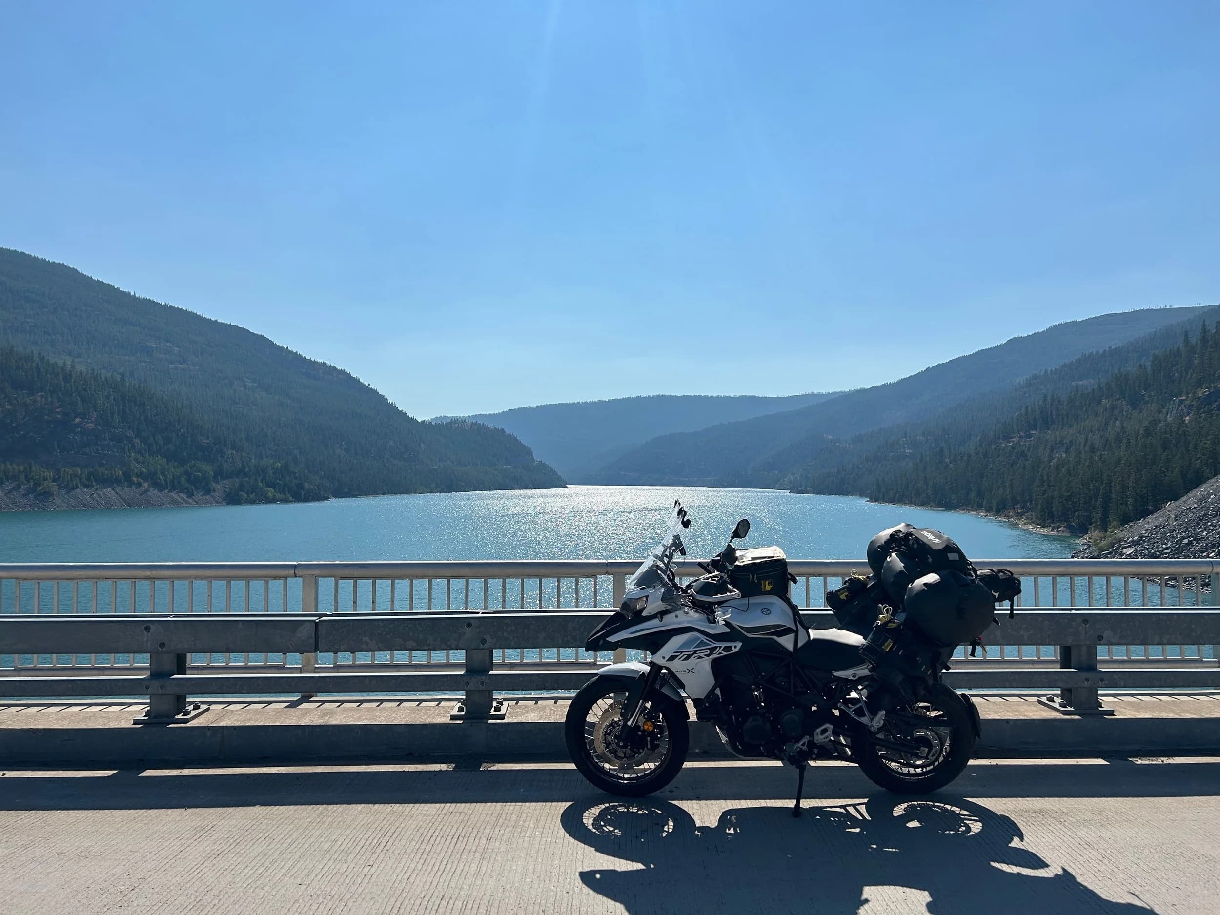 Trip Report: NW National Parks Loop
I left my job recently to take a much needed sabbatical and figure out what I’m doing next. A few weeks after my last day at work I embarked on what was to be a three week tour of NW-ish National Parks from Portland, to include Olympic, North Cascades, Glacier, Yellowstone, Grand Teton, Craters of the Moon, Lassen Volcanic, and Crater Lake.
I ended up missing Grand Tetons due to weather and I had to cut the trip short before I got to Lassen (family medical issue), so Lassen and Crater Lake remain unvisited.
Trip Dates: Sept 3 - Sept 16 (13 days)
Total Travel Miles: 3478 (does not include local miles for store runs, etc.)
Total Gallons of Gas Used: 82
Equipment: 2021 Benelli TRK502X Gaia GPS & Google Maps running on Sonim XP8 rugged Android phoneButler Motorcycle Maps (paper maps of best M/C roads in the country) iPhone 14 (main camera) Akaso Brave 7 helmet-mounted adventure camera Spot X satellite communicator and tracker Wolfman Luggage WP waterproof tank bag and saddle bags (no longer available) Watershed Colorado dry bag duffel (across the pillion seat) Kriega US-5 Drypack (tail bag) Kriega 3L hydration backpack (strapped to duffel, not worn)Marmot Ajax 2 tent Nemo hydrophobic down sleeping bag (non-mummy)Helinox ultralight cot MSR WhisperLite International stove
(Purchased in 1991 for my first moto trip: Detroit, MI to San Diego and back on an XT250)Gossamer Gear Bare Boxer bear-proof food canisters (two - one in each saddle bag)
Day 1 - Olympic National Park Date: Tuesday 9/3/2024
Destination: South Beach Campground, Olympic National Park
Travel Time: 4h 24m
Miles: 213Notes:
Planned to head west to Astoria then north from there, but left later than expected so headed up I-5 to US 12. I’ve driven/ridden that stretch of I-5 hundreds of times (starting in 1993). It’s boring and I hate it.
South Beach CG is first-come-first-served. I didn’t have issue getting a site. There is a long, tight loop of sites along the coastline, but I chose one of the sites further back near the bathrooms due to wind concerns. The bathroom building provided a sort of wind shelter for my site.
I used the heated grips on this leg; it was pretty chilly along the coast in the Olympic Peninsula. I almost didn’t install them, thinking I was being paranoid about the cold. I ended up using them a lot.
Day 2 - Ferry to Seattle / Burien Date: Wednesday 9/4/2024
Destination: Friend’s house in Burien, WA
Travel Time: 7h 30m
Miles: 199
Notes:
Slept well (thanks to Advil PM). I’ve not been sleeping well for more than a year. I’m really hoping to reset my sleep patterns with this trip. A good night’s sleep is one of my great joys and I feel like I’ve been robbed of that pleasure.
Used my Aeropress this morning for the first time ever. I’m hooked.
Headed up along US 101 through Port Angeles and then down to the Southworth ferry terminal near Port Orchard. Ferried across to Fauntleroy, which is just a few miles north my friend’s house in Burien. I’m always surprised at how long it takes to get from the Olympic Peninsula to the east side of Puget Sound (Seattle, etc.). With the ferry crossing (I love ferries) it took seven and a half hours to go 200 miles.
Discovered at my first stop of the day (just up 101 at the Kalaloch Campground, stopped to refill water) that the battery is quite weak and won’t start the bike if you leave the ignition on for even two minutes without the motor running. This would become a theme for the next few days. Fortunately, I have a jumper box and a permanent jump harness wired to the battery so jump starts are a quick operation.
Had a good evening with old friends.
Day 3 - North Cascades via Mountain Loop RoadDate: Thursday 9/5/2024
Destination: Newhalem Campground, North Cascades National Park
Travel Time: 4h 30m
Miles: 146Notes:
Slept well, on the couch. No pills needed.
I realized yesterday that my summer riding gloves (Rev’It Dune) were a size (or two) too small. Rev’It gloves fit really tight and I feel like I can never get it quite right. And yet, I love them. So, I stopped at a Cycle Gear in Bellevue to pick up something summer weight (Dirt 3) that fit better. They’re better, but maybe still one size too small. Such is life.
From Bellevue, I rode north and took the Mountain Loop Hwy then on up north to North Cascades. It was a hot ride. Still summer.
A small section of the Mountain Loop Road is dirt/gravel, which I didn’t realize. No biggie. Was just surprised (clearly I didn’t study my maps closely enough). When riding solo on a bike that weighs over 500 lbs., I tend to avoid planning much off-pavement riding. That’s what my DR-Z is for.
Day 4 - Newport, Washington via Winthrop Date: Friday 9/6/2024
Destination: Golden Spur Motor Inn, Newport, Washington
Travel Time: 8h
Miles: 308
Notes:
Slept just ok, even with Advil PM.
Pretty ride through North Cascades National Park and Colville National Forest. Didn’t do any backroads or hikes. Discovered (new to me) the town of Winthrop. Stopped for coffee at Sheri’s and resupplied on freeze-dried food at Cascades Outdoor Store.
The town of Newport is almost nothing, but, inexplicably, there’s an amazing restaurant (Brownell’s Place). Had dinner and a few ciders. Met and chatted with the owner/chef (she’s great). Listened to some live music. Then back to the motel.
Day 5 - New Battery in Kalispell Date: Saturday 9/7/2024
Destination: West Glacier KOA, West Glacier, MT
Travel Time: 8h 7m
Miles: 293
Notes:
Slept well on motel bed (on sleeping bag, not in the sheets). Another hot one.
Discovered that the water pump seal leaks oil. A quick post in the TRK Facebook group revealed that this is a common problem on this bike, and and easy fix. It’s apparently just a bad o-ring.
Battery has been getting continuously worse, and now requires I jump start the bike about every other start. Google Maps to the rescue: directions to the Batteries Plus in Kalispell, please. They don’t have an Odyssey AGM in the right size; the Duracell will have to do. (It’s been great.)
I set up camp at the West Glacier KOA, which will be my base for a few days. KOAs are their own little world. Very strange. Not really my thing, but the on-site laundry was handy.
After setting up camp I opened a cider and used the iPad to book a vehicle reservation for the next day to ride Going to the Sun Road, which I really wanted to do.
Day 6 - Going to the Sun RoadDate: Sunday 9/8/2024
Destination: Local Ride: West Glacier, Going to the Sun Road, Saint Mary, East Glacier
Travel Time: 5h 35m
Miles: 142Notes:
Quick breakfast and gas up in West Glacier before entering Going to the Sun Road.
Going to the Sun Road was stunning. This was the first point in the trip where I had tingles and was giddy at what I was seeing.
Took a very short hike along Saint Mary Lake. Again, I was beside myself with the beauty.
Lunch at the general store in Kiowa.
The rest of the ride back after East Glacier was meh, but I just kept thinking about how amazing what I’d seen in the morning had been.
Dinner at the KOA. Tacos from a cart (ok / not great, and a very weird guacamole) and a few glasses of wine from another cart. I asked about the guac and it turns out they make it in a food processor. Come on, people.
Day 7 - Ride to BozemanDate: Monday 9/9/2024
Destination: Friend’s house in Bozeman, Montana
Travel Time: ~ 8h (Gaia crashed near the end of the trip, but before getting to Bozeman)
Miles: ~ 400Notes:
Slept poorly again. No pills this time. Took some photos of my soft luggage setup to answer some questions in the TRK502X Facebook group. The saddle bags are from Wolfman Luggage, but I don’t think they make this waterproof line anymore. I use a duffel dry bag from Watershed across the top. A heat shield protects the side bag from exhaust heat.
Hazy, smoky ride most of the way. Very windy in places. This is where I first really started to feel how underpowered the TRK502 is. Really struggled in places.
Developed an engine-speed-sensitive squeak or rattle. Sounds like when a heat shield vibrates in resonance with engine vibration. Discovered that it’s a missing crash bar mounting bolt allowing the crash bar to rub against the frame.
Also noticed that there’s a resonant oscillation at speed that feels like the chain going bad (like it’s stretching unevenly).
First of several nights at a friend’s house in Bozeman (which, it turns out, is a pretty cool town). And there’s a hot tub…
Day 8 - Bike Maintenance & Hyalite ReservoirDate: Tuesday 9/10/2024
Destination: Local Ride: Hyalite Reservoir
Travel Time: not recorded
Miles: not recordedNotes:
Woke up to a smoky sunrise. I had the best night’s sleep I’ve had in years. This is was the whole point of this trip: to untangle my burnout and reclaim sleep as one of my joys. I wrote about it in my journal when I woke up. I hope this wasn’t a fluke.
Planned to replace the bolt that rattled loose from the crash bar, but instead discovered that it had actually severed off at the mount point. No fixing that on the road. Adjusted chain and moved on.
Lunch at Mountains Walking Brewery in Bozeman.
Rode up to Hyalite Reservoir. Pretty ride. Smoky still.
Soaked in hot tub after dinner.
Day 9 - North Yellowstone LoopDate: Wednesday 9/11/2024
Destination: Northern loop through Yellowstone National Park
Travel Time: 9h 36m
Miles: 272Notes:
Did a day trip from Bozeman down through the northern loop in Yellowstone, entering at Mammoth and taking the scenic route through Paradise Valley.
Saw elk, coyotes (I think), buffalo, and pronghorn.
Pretty ride, but cold in places. Used heated grips again.
Rode the loop through Mammoth Hot Springs (see video) at the end.
Coffee at Tumbleweed Bookstore & Cafe in Gardiner. I kind of dig Gardiner. Good vibe.
Had dinner at Mountains Walking Brewing. Rain and wind started. Lights flickered. Waited for rain to stop before riding back to the house.
Power out at the house due to high winds. This does not bode well for tomorrow.
Day 10 - Winter Weather in the ParksDate: Thursday 9/12/2024
Destination: Grand Teton National Park via West Yellowstone Pocatello, Idaho
Travel Time: 5h 40m
Miles: 201Notes:
Today was supposed to be a gorgeous ride through Yellowstone into Grand Teton National Park, and camping at Signal Mountain CG in the park. The weather had other ideas. It was pouring rain (and cold) all the way to West Yellowstone from Bozeman. By the time I got to West Yellowstone I was getting severe winter weather warnings on my phone calling for up to 3 (three!!) inches of snow accumulating in the high passes in the park. It’s bad enough in a car, but that’s a disaster waiting to happen on a motorcycle.
I parked my butt at Mountain Mama’s Cafe in West Yellowstone to warm up / dry off and decide what to do. I almost had myself convinced to push through when I realized that, even if I made it to the campground ok, I’d be setting up camp in the rain and I’d likely be miserable all night. Grand Teton would have to wait.
From West Yellowstone it’s easy to bail west into Idaho and get away from the park weather and elevations. So that’s what I did. It was not a pleasant ride, though. I was in torrential downpours all the way to Idaho Falls.
Arriving in Idaho Falls, I was exhausted and sure I could just find a room for the night. I dropped the bike at a roundabout (short-legged it coming to a stop; I knew it was going so I just rolled away). Guy behind me helped me pick it up. Then, there were no rooms because it was move in week for the two universities there (U of I, ISU). This would become a recurring theme.
I rode further to Blackfoot. Still no rooms.
I called ahead to Pocatello and got a room at a Red Lion there. I was never so happy to be off the bike.
No pictures this day. I couldn’t even get the action camera to turn on.
Day 11 - Craters of the Moon and EBR-1Date: Friday 9/13/2024
Destination: Craters of the Moon National Monument
Travel Time: 4h 20m
Miles: 124
Notes:
I wasn’t sure what my destination would be today but my plan was to do a little nuclear tourism, see Craters of the Moon, and then go somewhere from there. My schedule and day-plan was thrown off by missing Grand Teton National Park and spending a night in Pocatello, which was not on the itinerary at all.
Stopped in Atomic City. Not sure why; I was under the impression that Atomic City was the first city lit by nuclear engergy, but it was practically a ghost town. There are a few houses there, but as far as I could tell all of the business were shuttered. Except, maybe, for the race track; that looked like it might still get used.
Arco, it turns out, is the city celebrated as the first in the world to be lit by nuclear energy. Nothing special about the town, but they do a nice job of making City Hall photo-worthy.
Between Atomic City and Arco is EBR-1 (Experimental Breeder Reactor I) which was the world’s first breeder reactor. The EBR-1 exhibit was closed for the season, but in the lot next to it were some really interesting experimental nuclear heat-transfer jet engines that never made it out of the experimental phase (probably a good thing).
Craters of the Moon is pretty small. If you don’t do any of the walks, it’s literally just a 30 minute road loop. Still, it was an unexpected surprise and delight. I had no idea what to expect but I was positively chuffed at the experience. I noticed that the campground had open sites so I inquired at the entry booth. As luck would have it, the whole campground is first come / first serve. I decided to set up for the night. It’s good to be done early and have some time to read and not stress about making distance.
Day 12 - New Chain in Twin FallsDate: Saturday 9/14/2024
Destination: Battle Mountain, Nevada
Travel Time: 8h 52m
Miles: 335
Notes:
Beautiful morning in Craters of the Moon. While I was breaking camp a parade of classic cars came into the park to drive the loop. I got a picture of one Pontiac down the road in Carey at a gas station.
Carey ended up being an unplanned fork in the road for me. I discovered this morning that my chain was indeed stretching unevenly, and the oscillation I was feeling and hearing was the chain hum changing from a “loose” hum to a “tight” hum rapidly as the tight spot moved around the sprockets. I was supposed to continue west to Mountain Home and then south from there into Nevada. A very scenic route, according to my Butler map. But, between camp and the gas station I got pretty paranoid about the chain snapping at high speed, which, worst case, could lead to a fatal crash.
So I called ahead to a few motorcycle dealers in Mountain Home (on my planned route) to see if they could take me in and replace the chain. No dice. This is the downside of having an obscure motorcycle from an obscure marque - no one wants to work on it. Making matters worse this is an Italian-designed bike built in China, a fact which causes many people to lose the ability to think clearly. “It’s Chinese junk!” Not so. Next.
With Mountain Home out, I tried Twin Falls. My first call was to Adventure Motorsports, and the service manager there took me in with no hesitation. “How soon can you be here?” I didn’t get his name, but my hat’s off to him and his one tech working furiously on a Saturday to beat the 3pm closing time. He said during high season, they get about 15-20 out of town travelers per week who need something done, and they take them all in. I love to hear stuff like this. This shop is in it for the community. They have a nice showroom, too.
With a quality new chain installed, I got a burrito and a MexiCoke at a Mexican place and went on my way. I made it to Battle Mountain, NV, where I decide to get a room. Tomorrow I rejoin my planned scenic route. Day 13 - Desert Mountains in NV, CADate: Sunday 9/15/2024
Destination: Grizzly Campground, Lake Davis (near Portola, CA)
Travel Time: 7h
Miles: 307
Notes:
I love the northern Nevada landscape, and today’s ride didn’t disappoint. US Highway 50 is apparently known as “The Loneliest Highway” but everyone knows about it, so it’s not very lonely. However, after leaving Austin, NV headed west you can take Nevada Highway 722, which dips to the south and follows the old US 50 route. It was completely empty and the twisties through the passes were fun. Highly recommended.
Stopped in Fallon for gas and to find a Micro SD card for the action camera. Walmart to the rescue.
After Reno, I crossed into California and, I swear, it looks different. Norther California desert mountains are so beautiful.
Camped at a nearly empty campground on Lake Davis (very end of the season). The host warned me rain was coming tomorrow.
Day 14 - Unplanned Return HomeDate: Monday 9/16/2024
Destination: Summit Lake Campground, Lassen Volcanic National Park Portland, Oregon (Home)
Travel Time: 10h 32m
Miles: 538Notes:
Last week, my mom went into the hospital for a fairly routine procedure. My brother went to Michigan to help out, as needed, and he went back home to Arizona after she returned home and everything seemed settled.
This morning, while having coffee, I got a call that she’d gone back into the hospital with something that may or may not have been related to the procedure. It seemed like maybe things were ok, but maybe not.
I decided the best thing to do was head home so that I was near an airport if I needed to fly out to Michigan to help out.
I packed up camp and headed up US 395 toward home, via Klamath Falls. It was a pretty ride, but, once again, I found myself in rain most of the way to Klamath Falls.
I was pretty beat by the time I got to Klamath Falls and figured I’d just find a hotel room, get a hot shower, and finish the ride tomorrow.
But, once again, it was move-in week for the local university. Holiday Inn Express had a single room for $395. No thanks. Onward.
I never hit rain again after Klamath Falls, and after turning west onto Oregon Hwy 58 and starting to lose elevation into the Willamette Valley, the temperature starting rising, which was welcome.
Once I reached Eugene, there was no point in not just going all the way home, so that’s what I did.
I got two pictures: one at camp before the call, and one at my last gas stop, an hour and twenty minutes from home, with the moon rising.
A nice side effect of my early return home is that I was home for my birthday (tomorrow), so I had dinner with my kids and my wife, which was lovely.
I did end up flying to Michigan the next day, and was there for a bit. The best part? I got to make some meals for my mom and step dad. Everything seems ok with my mom for now.
Grand Teton, Lassen, and Crater Lake will be there, and now I have an excuse for another trip in the future.