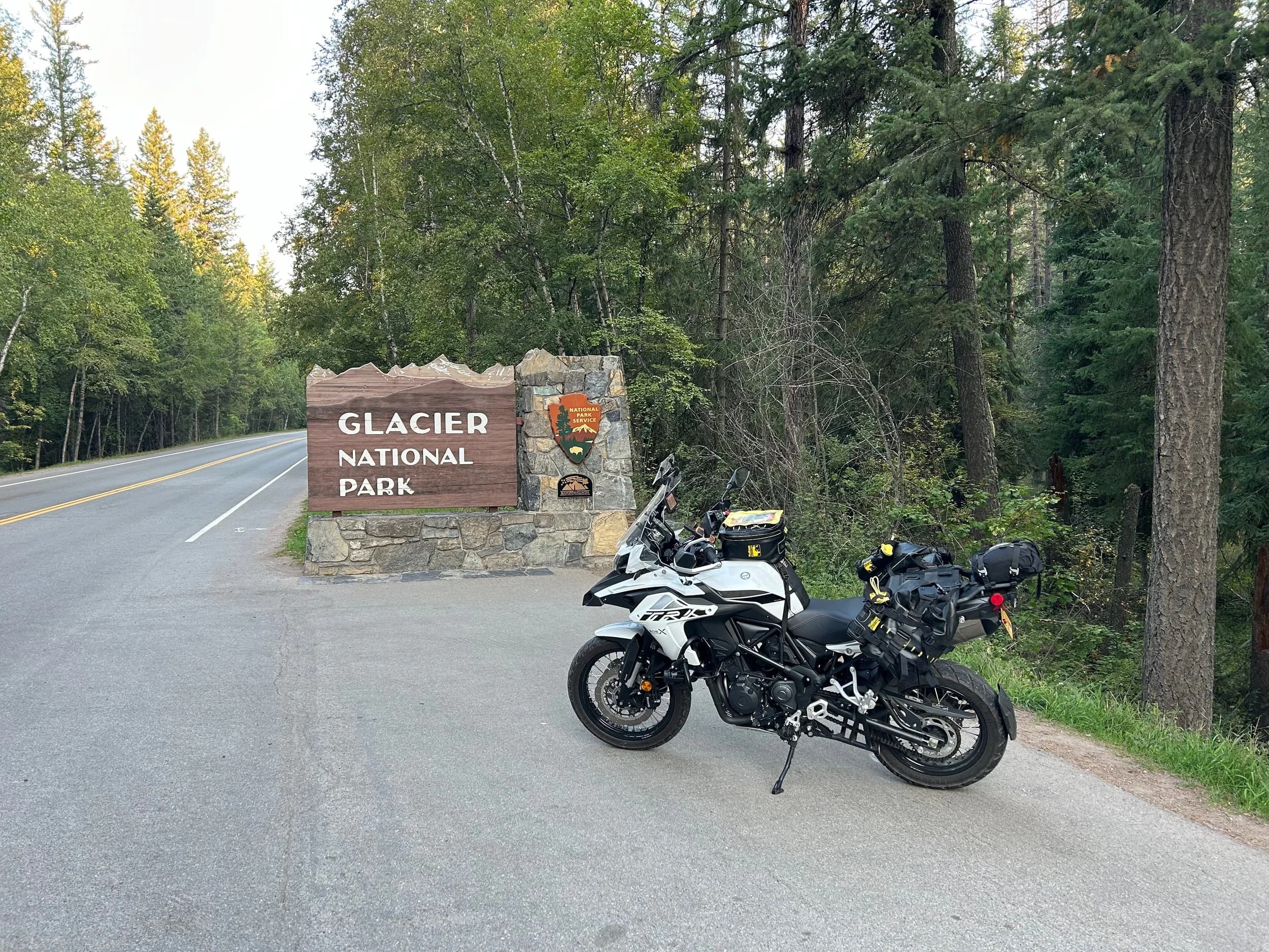 Trip Report: NW National Parks Loop
I left my job recently to take a much needed sabbatical and figure out what I’m doing next. A few weeks after my last day at work I embarked on what was to be a three week tour of NW-ish National Parks from Portland, to include Olympic, North Cascades, Glacier, Yellowstone, Grand Teton, Craters of the Moon, Lassen Volcanic, and Crater Lake.
I ended up missing Grand Tetons due to weather and I had to cut the trip short before I got to Lassen (family medical issue), so Lassen and Crater Lake remain unvisited.
Trip Dates: Sept 3 - Sept 16 (13 days)
Total Travel Miles: 3478 (does not include local miles for store runs, etc.)
Total Gallons of Gas Used: 82
Equipment: 2021 Benelli TRK502X Gaia GPS & Google Maps running on Sonim XP8 rugged Android phoneButler Motorcycle Maps (paper maps of best M/C roads in the country) iPhone 14 (main camera) Akaso Brave 7 helmet-mounted adventure camera Spot X satellite communicator and tracker Wolfman Luggage WP waterproof tank bag and saddle bags (no longer available) Watershed Colorado dry bag duffel (across the pillion seat) Kriega US-5 Drypack (tail bag) Kriega 3L hydration backpack (strapped to duffel, not worn)Marmot Ajax 2 tent Nemo hydrophobic down sleeping bag (non-mummy)Helinox ultralight cot MSR WhisperLite International stove
(Purchased in 1991 for my first moto trip: Detroit, MI to San Diego and back on an XT250)Gossamer Gear Bare Boxer bear-proof food canisters (two - one in each saddle bag)
Day 1 - Olympic National Park Date: Tuesday 9/3/2024
Destination: South Beach Campground, Olympic National Park
Travel Time: 4h 24m
Miles: 213Notes:
Planned to head west to Astoria then north from there, but left later than expected so headed up I-5 to US 12. I’ve driven/ridden that stretch of I-5 hundreds of times (starting in 1993). It’s boring and I hate it.
South Beach CG is first-come-first-served. I didn’t have issue getting a site. There is a long, tight loop of sites along the coastline, but I chose one of the sites further back near the bathrooms due to wind concerns. The bathroom building provided a sort of wind shelter for my site.
I used the heated grips on this leg; it was pretty chilly along the coast in the Olympic Peninsula. I almost didn’t install them, thinking I was being paranoid about the cold. I ended up using them a lot.
Day 2 - Ferry to Seattle / Burien Date: Wednesday 9/4/2024
Destination: Friend’s house in Burien, WA
Travel Time: 7h 30m
Miles: 199
Notes:
Slept well (thanks to Advil PM). I’ve not been sleeping well for more than a year. I’m really hoping to reset my sleep patterns with this trip. A good night’s sleep is one of my great joys and I feel like I’ve been robbed of that pleasure.
Used my Aeropress this morning for the first time ever. I’m hooked.
Headed up along US 101 through Port Angeles and then down to the Southworth ferry terminal near Port Orchard. Ferried across to Fauntleroy, which is just a few miles north my friend’s house in Burien. I’m always surprised at how long it takes to get from the Olympic Peninsula to the east side of Puget Sound (Seattle, etc.). With the ferry crossing (I love ferries) it took seven and a half hours to go 200 miles.
Discovered at my first stop of the day (just up 101 at the Kalaloch Campground, stopped to refill water) that the battery is quite weak and won’t start the bike if you leave the ignition on for even two minutes without the motor running. This would become a theme for the next few days. Fortunately, I have a jumper box and a permanent jump harness wired to the battery so jump starts are a quick operation.
Had a good evening with old friends.
Day 3 - North Cascades via Mountain Loop RoadDate: Thursday 9/5/2024
Destination: Newhalem Campground, North Cascades National Park
Travel Time: 4h 30m
Miles: 146Notes:
Slept well, on the couch. No pills needed.
I realized yesterday that my summer riding gloves (Rev’It Dune) were a size (or two) too small. Rev’It gloves fit really tight and I feel like I can never get it quite right. And yet, I love them. So, I stopped at a Cycle Gear in Bellevue to pick up something summer weight (Dirt 3) that fit better. They’re better, but maybe still one size too small. Such is life.
From Bellevue, I rode north and took the Mountain Loop Hwy then on up north to North Cascades. It was a hot ride. Still summer.
A small section of the Mountain Loop Road is dirt/gravel, which I didn’t realize. No biggie. Was just surprised (clearly I didn’t study my maps closely enough). When riding solo on a bike that weighs over 500 lbs., I tend to avoid planning much off-pavement riding. That’s what my DR-Z is for.
Day 4 - Newport, Washington via Winthrop Date: Friday 9/6/2024
Destination: Golden Spur Motor Inn, Newport, Washington
Travel Time: 8h
Miles: 308
Notes:
Slept just ok, even with Advil PM.
Pretty ride through North Cascades National Park and Colville National Forest. Didn’t do any backroads or hikes. Discovered (new to me) the town of Winthrop. Stopped for coffee at Sheri’s and resupplied on freeze-dried food at Cascades Outdoor Store.
The town of Newport is almost nothing, but, inexplicably, there’s an amazing restaurant (Brownell’s Place). Had dinner and a few ciders. Met and chatted with the owner/chef (she’s great). Listened to some live music. Then back to the motel.
Day 5 - New Battery in Kalispell Date: Saturday 9/7/2024
Destination: West Glacier KOA, West Glacier, MT
Travel Time: 8h 7m
Miles: 293
Notes:
Slept well on motel bed (on sleeping bag, not in the sheets). Another hot one.
Discovered that the water pump seal leaks oil. A quick post in the TRK Facebook group revealed that this is a common problem on this bike, and and easy fix. It’s apparently just a bad o-ring.
Battery has been getting continuously worse, and now requires I jump start the bike about every other start. Google Maps to the rescue: directions to the Batteries Plus in Kalispell, please. They don’t have an Odyssey AGM in the right size; the Duracell will have to do. (It’s been great.)
I set up camp at the West Glacier KOA, which will be my base for a few days. KOAs are their own little world. Very strange. Not really my thing, but the on-site laundry was handy.
After setting up camp I opened a cider and used the iPad to book a vehicle reservation for the next day to ride Going to the Sun Road, which I really wanted to do.
Day 6 - Going to the Sun RoadDate: Sunday 9/8/2024
Destination: Local Ride: West Glacier, Going to the Sun Road, Saint Mary, East Glacier
Travel Time: 5h 35m
Miles: 142Notes:
Quick breakfast and gas up in West Glacier before entering Going to the Sun Road.
Going to the Sun Road was stunning. This was the first point in the trip where I had tingles and was giddy at what I was seeing.
Took a very short hike along Saint Mary Lake. Again, I was beside myself with the beauty.
Lunch at the general store in Kiowa.
The rest of the ride back after East Glacier was meh, but I just kept thinking about how amazing what I’d seen in the morning had been.
Dinner at the KOA. Tacos from a cart (ok / not great, and a very weird guacamole) and a few glasses of wine from another cart. I asked about the guac and it turns out they make it in a food processor. Come on, people.
Day 7 - Ride to BozemanDate: Monday 9/9/2024
Destination: Friend’s house in Bozeman, Montana
Travel Time: ~ 8h (Gaia crashed near the end of the trip, but before getting to Bozeman)
Miles: ~ 400Notes:
Slept poorly again. No pills this time. Took some photos of my soft luggage setup to answer some questions in the TRK502X Facebook group. The saddle bags are from Wolfman Luggage, but I don’t think they make this waterproof line anymore. I use a duffel dry bag from Watershed across the top. A heat shield protects the side bag from exhaust heat.
Hazy, smoky ride most of the way. Very windy in places. This is where I first really started to feel how underpowered the TRK502 is. Really struggled in places.
Developed an engine-speed-sensitive squeak or rattle. Sounds like when a heat shield vibrates in resonance with engine vibration. Discovered that it’s a missing crash bar mounting bolt allowing the crash bar to rub against the frame.
Also noticed that there’s a resonant oscillation at speed that feels like the chain going bad (like it’s stretching unevenly).
First of several nights at a friend’s house in Bozeman (which, it turns out, is a pretty cool town). And there’s a hot tub…
Day 8 - Bike Maintenance & Hyalite ReservoirDate: Tuesday 9/10/2024
Destination: Local Ride: Hyalite Reservoir
Travel Time: not recorded
Miles: not recordedNotes:
Woke up to a smoky sunrise. I had the best night’s sleep I’ve had in years. This is was the whole point of this trip: to untangle my burnout and reclaim sleep as one of my joys. I wrote about it in my journal when I woke up. I hope this wasn’t a fluke.
Planned to replace the bolt that rattled loose from the crash bar, but instead discovered that it had actually severed off at the mount point. No fixing that on the road. Adjusted chain and moved on.
Lunch at Mountains Walking Brewery in Bozeman.
Rode up to Hyalite Reservoir. Pretty ride. Smoky still.
Soaked in hot tub after dinner.
Day 9 - North Yellowstone LoopDate: Wednesday 9/11/2024
Destination: Northern loop through Yellowstone National Park
Travel Time: 9h 36m
Miles: 272Notes:
Did a day trip from Bozeman down through the northern loop in Yellowstone, entering at Mammoth and taking the scenic route through Paradise Valley.
Saw elk, coyotes (I think), buffalo, and pronghorn.
Pretty ride, but cold in places. Used heated grips again.
Rode the loop through Mammoth Hot Springs (see video) at the end.
Coffee at Tumbleweed Bookstore & Cafe in Gardiner. I kind of dig Gardiner. Good vibe.
Had dinner at Mountains Walking Brewing. Rain and wind started. Lights flickered. Waited for rain to stop before riding back to the house.
Power out at the house due to high winds. This does not bode well for tomorrow.
Day 10 - Winter Weather in the ParksDate: Thursday 9/12/2024
Destination: Grand Teton National Park via West Yellowstone Pocatello, Idaho
Travel Time: 5h 40m
Miles: 201Notes:
Today was supposed to be a gorgeous ride through Yellowstone into Grand Teton National Park, and camping at Signal Mountain CG in the park. The weather had other ideas. It was pouring rain (and cold) all the way to West Yellowstone from Bozeman. By the time I got to West Yellowstone I was getting severe winter weather warnings on my phone calling for up to 3 (three!!) inches of snow accumulating in the high passes in the park. It’s bad enough in a car, but that’s a disaster waiting to happen on a motorcycle.
I parked my butt at Mountain Mama’s Cafe in West Yellowstone to warm up / dry off and decide what to do. I almost had myself convinced to push through when I realized that, even if I made it to the campground ok, I’d be setting up camp in the rain and I’d likely be miserable all night. Grand Teton would have to wait.
From West Yellowstone it’s easy to bail west into Idaho and get away from the park weather and elevations. So that’s what I did. It was not a pleasant ride, though. I was in torrential downpours all the way to Idaho Falls.
Arriving in Idaho Falls, I was exhausted and sure I could just find a room for the night. I dropped the bike at a roundabout (short-legged it coming to a stop; I knew it was going so I just rolled away). Guy behind me helped me pick it up. Then, there were no rooms because it was move in week for the two universities there (U of I, ISU). This would become a recurring theme.
I rode further to Blackfoot. Still no rooms.
I called ahead to Pocatello and got a room at a Red Lion there. I was never so happy to be off the bike.
No pictures this day. I couldn’t even get the action camera to turn on.
Day 11 - Craters of the Moon and EBR-1Date: Friday 9/13/2024
Destination: Craters of the Moon National Monument
Travel Time: 4h 20m
Miles: 124
Notes:
I wasn’t sure what my destination would be today but my plan was to do a little nuclear tourism, see Craters of the Moon, and then go somewhere from there. My schedule and day-plan was thrown off by missing Grand Teton National Park and spending a night in Pocatello, which was not on the itinerary at all.
Stopped in Atomic City. Not sure why; I was under the impression that Atomic City was the first city lit by nuclear engergy, but it was practically a ghost town. There are a few houses there, but as far as I could tell all of the business were shuttered. Except, maybe, for the race track; that looked like it might still get used.
Arco, it turns out, is the city celebrated as the first in the world to be lit by nuclear energy. Nothing special about the town, but they do a nice job of making City Hall photo-worthy.
Between Atomic City and Arco is EBR-1 (Experimental Breeder Reactor I) which was the world’s first breeder reactor. The EBR-1 exhibit was closed for the season, but in the lot next to it were some really interesting experimental nuclear heat-transfer jet engines that never made it out of the experimental phase (probably a good thing).
Craters of the Moon is pretty small. If you don’t do any of the walks, it’s literally just a 30 minute road loop. Still, it was an unexpected surprise and delight. I had no idea what to expect but I was positively chuffed at the experience. I noticed that the campground had open sites so I inquired at the entry booth. As luck would have it, the whole campground is first come / first serve. I decided to set up for the night. It’s good to be done early and have some time to read and not stress about making distance.
Day 12 - New Chain in Twin FallsDate: Saturday 9/14/2024
Destination: Battle Mountain, Nevada
Travel Time: 8h 52m
Miles: 335
Notes:
Beautiful morning in Craters of the Moon. While I was breaking camp a parade of classic cars came into the park to drive the loop. I got a picture of one Pontiac down the road in Carey at a gas station.
Carey ended up being an unplanned fork in the road for me. I discovered this morning that my chain was indeed stretching unevenly, and the oscillation I was feeling and hearing was the chain hum changing from a “loose” hum to a “tight” hum rapidly as the tight spot moved around the sprockets. I was supposed to continue west to Mountain Home and then south from there into Nevada. A very scenic route, according to my Butler map. But, between camp and the gas station I got pretty paranoid about the chain snapping at high speed, which, worst case, could lead to a fatal crash.
So I called ahead to a few motorcycle dealers in Mountain Home (on my planned route) to see if they could take me in and replace the chain. No dice. This is the downside of having an obscure motorcycle from an obscure marque - no one wants to work on it. Making matters worse this is an Italian-designed bike built in China, a fact which causes many people to lose the ability to think clearly. “It’s Chinese junk!” Not so. Next.
With Mountain Home out, I tried Twin Falls. My first call was to Adventure Motorsports, and the service manager there took me in with no hesitation. “How soon can you be here?” I didn’t get his name, but my hat’s off to him and his one tech working furiously on a Saturday to beat the 3pm closing time. He said during high season, they get about 15-20 out of town travelers per week who need something done, and they take them all in. I love to hear stuff like this. This shop is in it for the community. They have a nice showroom, too.
With a quality new chain installed, I got a burrito and a MexiCoke at a Mexican place and went on my way. I made it to Battle Mountain, NV, where I decide to get a room. Tomorrow I rejoin my planned scenic route. Day 13 - Desert Mountains in NV, CADate: Sunday 9/15/2024
Destination: Grizzly Campground, Lake Davis (near Portola, CA)
Travel Time: 7h
Miles: 307
Notes:
I love the northern Nevada landscape, and today’s ride didn’t disappoint. US Highway 50 is apparently known as “The Loneliest Highway” but everyone knows about it, so it’s not very lonely. However, after leaving Austin, NV headed west you can take Nevada Highway 722, which dips to the south and follows the old US 50 route. It was completely empty and the twisties through the passes were fun. Highly recommended.
Stopped in Fallon for gas and to find a Micro SD card for the action camera. Walmart to the rescue.
After Reno, I crossed into California and, I swear, it looks different. Norther California desert mountains are so beautiful.
Camped at a nearly empty campground on Lake Davis (very end of the season). The host warned me rain was coming tomorrow.
Day 14 - Unplanned Return HomeDate: Monday 9/16/2024
Destination: Summit Lake Campground, Lassen Volcanic National Park Portland, Oregon (Home)
Travel Time: 10h 32m
Miles: 538Notes:
Last week, my mom went into the hospital for a fairly routine procedure. My brother went to Michigan to help out, as needed, and he went back home to Arizona after she returned home and everything seemed settled.
This morning, while having coffee, I got a call that she’d gone back into the hospital with something that may or may not have been related to the procedure. It seemed like maybe things were ok, but maybe not.
I decided the best thing to do was head home so that I was near an airport if I needed to fly out to Michigan to help out.
I packed up camp and headed up US 395 toward home, via Klamath Falls. It was a pretty ride, but, once again, I found myself in rain most of the way to Klamath Falls.
I was pretty beat by the time I got to Klamath Falls and figured I’d just find a hotel room, get a hot shower, and finish the ride tomorrow.
But, once again, it was move-in week for the local university. Holiday Inn Express had a single room for $395. No thanks. Onward.
I never hit rain again after Klamath Falls, and after turning west onto Oregon Hwy 58 and starting to lose elevation into the Willamette Valley, the temperature starting rising, which was welcome.
Once I reached Eugene, there was no point in not just going all the way home, so that’s what I did.
I got two pictures: one at camp before the call, and one at my last gas stop, an hour and twenty minutes from home, with the moon rising.
A nice side effect of my early return home is that I was home for my birthday (tomorrow), so I had dinner with my kids and my wife, which was lovely.
I did end up flying to Michigan the next day, and was there for a bit. The best part? I got to make some meals for my mom and step dad. Everything seems ok with my mom for now.
Grand Teton, Lassen, and Crater Lake will be there, and now I have an excuse for another trip in the future.