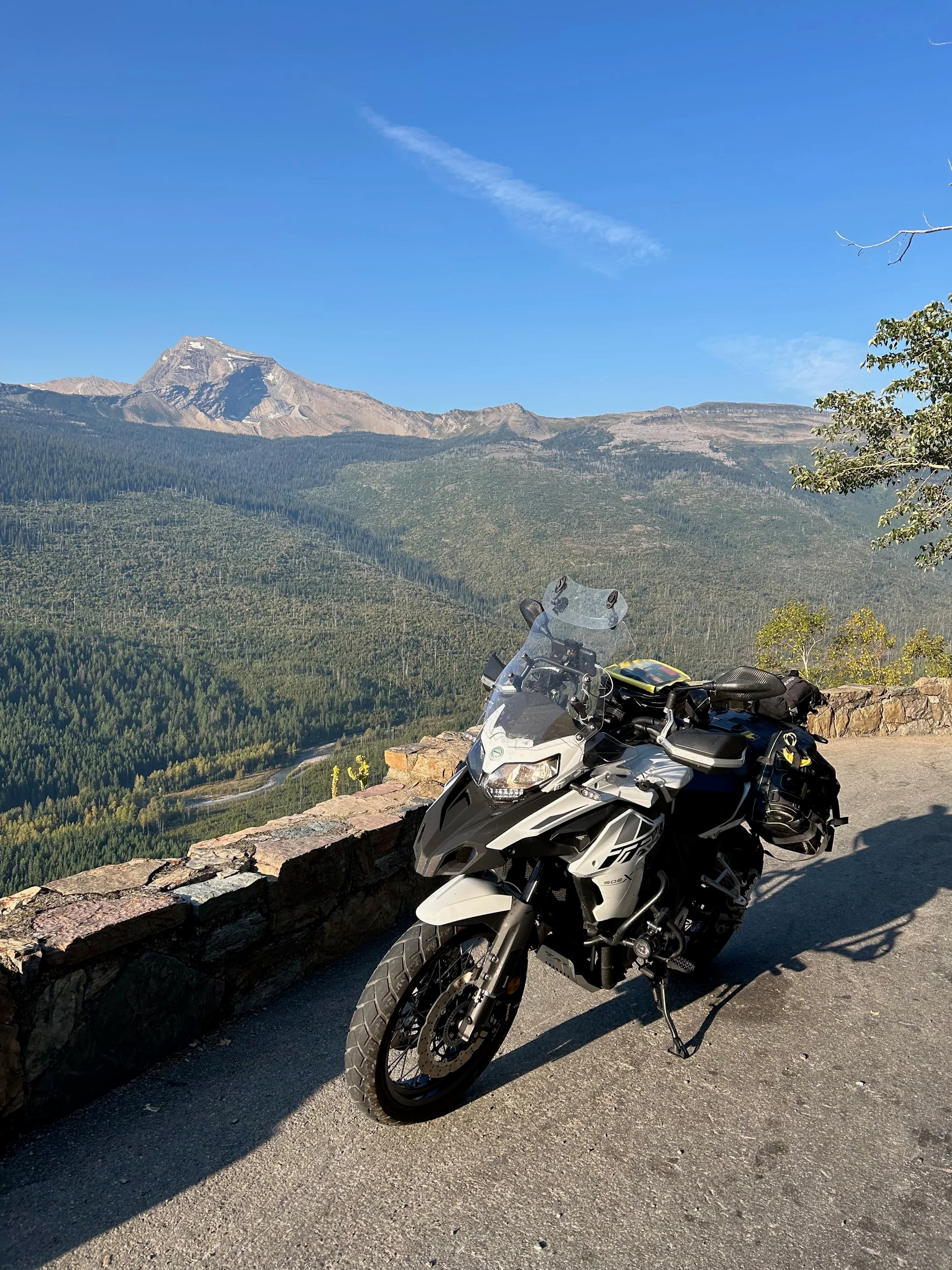 Trip Report: NW National Parks Loop
I left my job recently to take a much needed sabbatical and figure out what I’m doing next. A few weeks after my last day at work I embarked on what was to be a three week tour of NW-ish National Parks from Portland, to include Olympic, North Cascades, Glacier, Yellowstone, Grand Teton, Craters of the Moon, Lassen Volcanic, and Crater Lake.
I ended up missing Grand Tetons due to weather and I had to cut the trip short before I got to Lassen (family medical issue), so Lassen and Crater Lake remain unvisited.
Trip Dates: Sept 3 - Sept 16 (13 days)
Total Travel Miles: 3478 (does not include local miles for store runs, etc.)
Total Gallons of Gas Used: 82
Equipment: 2021 Benelli TRK502X Gaia GPS & Google Maps running on Sonim XP8 rugged Android phoneButler Motorcycle Maps (paper maps of best M/C roads in the country) iPhone 14 (main camera) Akaso Brave 7 helmet-mounted adventure camera Spot X satellite communicator and tracker Wolfman Luggage WP waterproof tank bag and saddle bags (no longer available) Watershed Colorado dry bag duffel (across the pillion seat) Kriega US-5 Drypack (tail bag) Kriega 3L hydration backpack (strapped to duffel, not worn)Marmot Ajax 2 tent Nemo hydrophobic down sleeping bag (non-mummy)Helinox ultralight cot MSR WhisperLite International stove
(Purchased in 1991 for my first moto trip: Detroit, MI to San Diego and back on an XT250)Gossamer Gear Bare Boxer bear-proof food canisters (two - one in each saddle bag)
Day 1 - Olympic National Park Date: Tuesday 9/3/2024
Destination: South Beach Campground, Olympic National Park
Travel Time: 4h 24m
Miles: 213Notes:
Planned to head west to Astoria then north from there, but left later than expected so headed up I-5 to US 12. I’ve driven/ridden that stretch of I-5 hundreds of times (starting in 1993). It’s boring and I hate it.
South Beach CG is first-come-first-served. I didn’t have issue getting a site. There is a long, tight loop of sites along the coastline, but I chose one of the sites further back near the bathrooms due to wind concerns. The bathroom building provided a sort of wind shelter for my site.
I used the heated grips on this leg; it was pretty chilly along the coast in the Olympic Peninsula. I almost didn’t install them, thinking I was being paranoid about the cold. I ended up using them a lot.
Day 2 - Ferry to Seattle / Burien Date: Wednesday 9/4/2024
Destination: Friend’s house in Burien, WA
Travel Time: 7h 30m
Miles: 199
Notes:
Slept well (thanks to Advil PM). I’ve not been sleeping well for more than a year. I’m really hoping to reset my sleep patterns with this trip. A good night’s sleep is one of my great joys and I feel like I’ve been robbed of that pleasure.
Used my Aeropress this morning for the first time ever. I’m hooked.
Headed up along US 101 through Port Angeles and then down to the Southworth ferry terminal near Port Orchard. Ferried across to Fauntleroy, which is just a few miles north my friend’s house in Burien. I’m always surprised at how long it takes to get from the Olympic Peninsula to the east side of Puget Sound (Seattle, etc.). With the ferry crossing (I love ferries) it took seven and a half hours to go 200 miles.
Discovered at my first stop of the day (just up 101 at the Kalaloch Campground, stopped to refill water) that the battery is quite weak and won’t start the bike if you leave the ignition on for even two minutes without the motor running. This would become a theme for the next few days. Fortunately, I have a jumper box and a permanent jump harness wired to the battery so jump starts are a quick operation.
Had a good evening with old friends.
Day 3 - North Cascades via Mountain Loop RoadDate: Thursday 9/5/2024
Destination: Newhalem Campground, North Cascades National Park
Travel Time: 4h 30m
Miles: 146Notes:
Slept well, on the couch. No pills needed.
I realized yesterday that my summer riding gloves (Rev’It Dune) were a size (or two) too small. Rev’It gloves fit really tight and I feel like I can never get it quite right. And yet, I love them. So, I stopped at a Cycle Gear in Bellevue to pick up something summer weight (Dirt 3) that fit better. They’re better, but maybe still one size too small. Such is life.
From Bellevue, I rode north and took the Mountain Loop Hwy then on up north to North Cascades. It was a hot ride. Still summer.
A small section of the Mountain Loop Road is dirt/gravel, which I didn’t realize. No biggie. Was just surprised (clearly I didn’t study my maps closely enough). When riding solo on a bike that weighs over 500 lbs., I tend to avoid planning much off-pavement riding. That’s what my DR-Z is for.
Day 4 - Newport, Washington via Winthrop Date: Friday 9/6/2024
Destination: Golden Spur Motor Inn, Newport, Washington
Travel Time: 8h
Miles: 308
Notes:
Slept just ok, even with Advil PM.
Pretty ride through North Cascades National Park and Colville National Forest. Didn’t do any backroads or hikes. Discovered (new to me) the town of Winthrop. Stopped for coffee at Sheri’s and resupplied on freeze-dried food at Cascades Outdoor Store.
The town of Newport is almost nothing, but, inexplicably, there’s an amazing restaurant (Brownell’s Place). Had dinner and a few ciders. Met and chatted with the owner/chef (she’s great). Listened to some live music. Then back to the motel.
Day 5 - New Battery in Kalispell Date: Saturday 9/7/2024
Destination: West Glacier KOA, West Glacier, MT
Travel Time: 8h 7m
Miles: 293
Notes:
Slept well on motel bed (on sleeping bag, not in the sheets). Another hot one.
Discovered that the water pump seal leaks oil. A quick post in the TRK Facebook group revealed that this is a common problem on this bike, and and easy fix. It’s apparently just a bad o-ring.
Battery has been getting continuously worse, and now requires I jump start the bike about every other start. Google Maps to the rescue: directions to the Batteries Plus in Kalispell, please. They don’t have an Odyssey AGM in the right size; the Duracell will have to do. (It’s been great.)
I set up camp at the West Glacier KOA, which will be my base for a few days. KOAs are their own little world. Very strange. Not really my thing, but the on-site laundry was handy.
After setting up camp I opened a cider and used the iPad to book a vehicle reservation for the next day to ride Going to the Sun Road, which I really wanted to do.
Day 6 - Going to the Sun RoadDate: Sunday 9/8/2024
Destination: Local Ride: West Glacier, Going to the Sun Road, Saint Mary, East Glacier
Travel Time: 5h 35m
Miles: 142Notes:
Quick breakfast and gas up in West Glacier before entering Going to the Sun Road.
Going to the Sun Road was stunning. This was the first point in the trip where I had tingles and was giddy at what I was seeing.
Took a very short hike along Saint Mary Lake. Again, I was beside myself with the beauty.
Lunch at the general store in Kiowa.
The rest of the ride back after East Glacier was meh, but I just kept thinking about how amazing what I’d seen in the morning had been.
Dinner at the KOA. Tacos from a cart (ok / not great, and a very weird guacamole) and a few glasses of wine from another cart. I asked about the guac and it turns out they make it in a food processor. Come on, people.
Day 7 - Ride to BozemanDate: Monday 9/9/2024
Destination: Friend’s house in Bozeman, Montana
Travel Time: ~ 8h (Gaia crashed near the end of the trip, but before getting to Bozeman)
Miles: ~ 400Notes:
Slept poorly again. No pills this time. Took some photos of my soft luggage setup to answer some questions in the TRK502X Facebook group. The saddle bags are from Wolfman Luggage, but I don’t think they make this waterproof line anymore. I use a duffel dry bag from Watershed across the top. A heat shield protects the side bag from exhaust heat.
Hazy, smoky ride most of the way. Very windy in places. This is where I first really started to feel how underpowered the TRK502 is. Really struggled in places.
Developed an engine-speed-sensitive squeak or rattle. Sounds like when a heat shield vibrates in resonance with engine vibration. Discovered that it’s a missing crash bar mounting bolt allowing the crash bar to rub against the frame.
Also noticed that there’s a resonant oscillation at speed that feels like the chain going bad (like it’s stretching unevenly).
First of several nights at a friend’s house in Bozeman (which, it turns out, is a pretty cool town). And there’s a hot tub…
Day 8 - Bike Maintenance & Hyalite ReservoirDate: Tuesday 9/10/2024
Destination: Local Ride: Hyalite Reservoir
Travel Time: not recorded
Miles: not recordedNotes:
Woke up to a smoky sunrise. I had the best night’s sleep I’ve had in years. This is was the whole point of this trip: to untangle my burnout and reclaim sleep as one of my joys. I wrote about it in my journal when I woke up. I hope this wasn’t a fluke.
Planned to replace the bolt that rattled loose from the crash bar, but instead discovered that it had actually severed off at the mount point. No fixing that on the road. Adjusted chain and moved on.
Lunch at Mountains Walking Brewery in Bozeman.
Rode up to Hyalite Reservoir. Pretty ride. Smoky still.
Soaked in hot tub after dinner.
Day 9 - North Yellowstone LoopDate: Wednesday 9/11/2024
Destination: Northern loop through Yellowstone National Park
Travel Time: 9h 36m
Miles: 272Notes:
Did a day trip from Bozeman down through the northern loop in Yellowstone, entering at Mammoth and taking the scenic route through Paradise Valley.
Saw elk, coyotes (I think), buffalo, and pronghorn.
Pretty ride, but cold in places. Used heated grips again.
Rode the loop through Mammoth Hot Springs (see video) at the end.
Coffee at Tumbleweed Bookstore & Cafe in Gardiner. I kind of dig Gardiner. Good vibe.
Had dinner at Mountains Walking Brewing. Rain and wind started. Lights flickered. Waited for rain to stop before riding back to the house.
Power out at the house due to high winds. This does not bode well for tomorrow.
Day 10 - Winter Weather in the ParksDate: Thursday 9/12/2024
Destination: Grand Teton National Park via West Yellowstone Pocatello, Idaho
Travel Time: 5h 40m
Miles: 201Notes:
Today was supposed to be a gorgeous ride through Yellowstone into Grand Teton National Park, and camping at Signal Mountain CG in the park. The weather had other ideas. It was pouring rain (and cold) all the way to West Yellowstone from Bozeman. By the time I got to West Yellowstone I was getting severe winter weather warnings on my phone calling for up to 3 (three!!) inches of snow accumulating in the high passes in the park. It’s bad enough in a car, but that’s a disaster waiting to happen on a motorcycle.
I parked my butt at Mountain Mama’s Cafe in West Yellowstone to warm up / dry off and decide what to do. I almost had myself convinced to push through when I realized that, even if I made it to the campground ok, I’d be setting up camp in the rain and I’d likely be miserable all night. Grand Teton would have to wait.
From West Yellowstone it’s easy to bail west into Idaho and get away from the park weather and elevations. So that’s what I did. It was not a pleasant ride, though. I was in torrential downpours all the way to Idaho Falls.
Arriving in Idaho Falls, I was exhausted and sure I could just find a room for the night. I dropped the bike at a roundabout (short-legged it coming to a stop; I knew it was going so I just rolled away). Guy behind me helped me pick it up. Then, there were no rooms because it was move in week for the two universities there (U of I, ISU). This would become a recurring theme.
I rode further to Blackfoot. Still no rooms.
I called ahead to Pocatello and got a room at a Red Lion there. I was never so happy to be off the bike.
No pictures this day. I couldn’t even get the action camera to turn on.
Day 11 - Craters of the Moon and EBR-1Date: Friday 9/13/2024
Destination: Craters of the Moon National Monument
Travel Time: 4h 20m
Miles: 124
Notes:
I wasn’t sure what my destination would be today but my plan was to do a little nuclear tourism, see Craters of the Moon, and then go somewhere from there. My schedule and day-plan was thrown off by missing Grand Teton National Park and spending a night in Pocatello, which was not on the itinerary at all.
Stopped in Atomic City. Not sure why; I was under the impression that Atomic City was the first city lit by nuclear engergy, but it was practically a ghost town. There are a few houses there, but as far as I could tell all of the business were shuttered. Except, maybe, for the race track; that looked like it might still get used.
Arco, it turns out, is the city celebrated as the first in the world to be lit by nuclear energy. Nothing special about the town, but they do a nice job of making City Hall photo-worthy.
Between Atomic City and Arco is EBR-1 (Experimental Breeder Reactor I) which was the world’s first breeder reactor. The EBR-1 exhibit was closed for the season, but in the lot next to it were some really interesting experimental nuclear heat-transfer jet engines that never made it out of the experimental phase (probably a good thing).
Craters of the Moon is pretty small. If you don’t do any of the walks, it’s literally just a 30 minute road loop. Still, it was an unexpected surprise and delight. I had no idea what to expect but I was positively chuffed at the experience. I noticed that the campground had open sites so I inquired at the entry booth. As luck would have it, the whole campground is first come / first serve. I decided to set up for the night. It’s good to be done early and have some time to read and not stress about making distance.
Day 12 - New Chain in Twin FallsDate: Saturday 9/14/2024
Destination: Battle Mountain, Nevada
Travel Time: 8h 52m
Miles: 335
Notes:
Beautiful morning in Craters of the Moon. While I was breaking camp a parade of classic cars came into the park to drive the loop. I got a picture of one Pontiac down the road in Carey at a gas station.
Carey ended up being an unplanned fork in the road for me. I discovered this morning that my chain was indeed stretching unevenly, and the oscillation I was feeling and hearing was the chain hum changing from a “loose” hum to a “tight” hum rapidly as the tight spot moved around the sprockets. I was supposed to continue west to Mountain Home and then south from there into Nevada. A very scenic route, according to my Butler map. But, between camp and the gas station I got pretty paranoid about the chain snapping at high speed, which, worst case, could lead to a fatal crash.
So I called ahead to a few motorcycle dealers in Mountain Home (on my planned route) to see if they could take me in and replace the chain. No dice. This is the downside of having an obscure motorcycle from an obscure marque - no one wants to work on it. Making matters worse this is an Italian-designed bike built in China, a fact which causes many people to lose the ability to think clearly. “It’s Chinese junk!” Not so. Next.
With Mountain Home out, I tried Twin Falls. My first call was to Adventure Motorsports, and the service manager there took me in with no hesitation. “How soon can you be here?” I didn’t get his name, but my hat’s off to him and his one tech working furiously on a Saturday to beat the 3pm closing time. He said during high season, they get about 15-20 out of town travelers per week who need something done, and they take them all in. I love to hear stuff like this. This shop is in it for the community. They have a nice showroom, too.
With a quality new chain installed, I got a burrito and a MexiCoke at a Mexican place and went on my way. I made it to Battle Mountain, NV, where I decide to get a room. Tomorrow I rejoin my planned scenic route. Day 13 - Desert Mountains in NV, CADate: Sunday 9/15/2024
Destination: Grizzly Campground, Lake Davis (near Portola, CA)
Travel Time: 7h
Miles: 307
Notes:
I love the northern Nevada landscape, and today’s ride didn’t disappoint. US Highway 50 is apparently known as “The Loneliest Highway” but everyone knows about it, so it’s not very lonely. However, after leaving Austin, NV headed west you can take Nevada Highway 722, which dips to the south and follows the old US 50 route. It was completely empty and the twisties through the passes were fun. Highly recommended.
Stopped in Fallon for gas and to find a Micro SD card for the action camera. Walmart to the rescue.
After Reno, I crossed into California and, I swear, it looks different. Norther California desert mountains are so beautiful.
Camped at a nearly empty campground on Lake Davis (very end of the season). The host warned me rain was coming tomorrow.
Day 14 - Unplanned Return HomeDate: Monday 9/16/2024
Destination: Summit Lake Campground, Lassen Volcanic National Park Portland, Oregon (Home)
Travel Time: 10h 32m
Miles: 538Notes:
Last week, my mom went into the hospital for a fairly routine procedure. My brother went to Michigan to help out, as needed, and he went back home to Arizona after she returned home and everything seemed settled.
This morning, while having coffee, I got a call that she’d gone back into the hospital with something that may or may not have been related to the procedure. It seemed like maybe things were ok, but maybe not.
I decided the best thing to do was head home so that I was near an airport if I needed to fly out to Michigan to help out.
I packed up camp and headed up US 395 toward home, via Klamath Falls. It was a pretty ride, but, once again, I found myself in rain most of the way to Klamath Falls.
I was pretty beat by the time I got to Klamath Falls and figured I’d just find a hotel room, get a hot shower, and finish the ride tomorrow.
But, once again, it was move-in week for the local university. Holiday Inn Express had a single room for $395. No thanks. Onward.
I never hit rain again after Klamath Falls, and after turning west onto Oregon Hwy 58 and starting to lose elevation into the Willamette Valley, the temperature starting rising, which was welcome.
Once I reached Eugene, there was no point in not just going all the way home, so that’s what I did.
I got two pictures: one at camp before the call, and one at my last gas stop, an hour and twenty minutes from home, with the moon rising.
A nice side effect of my early return home is that I was home for my birthday (tomorrow), so I had dinner with my kids and my wife, which was lovely.
I did end up flying to Michigan the next day, and was there for a bit. The best part? I got to make some meals for my mom and step dad. Everything seems ok with my mom for now.
Grand Teton, Lassen, and Crater Lake will be there, and now I have an excuse for another trip in the future.
