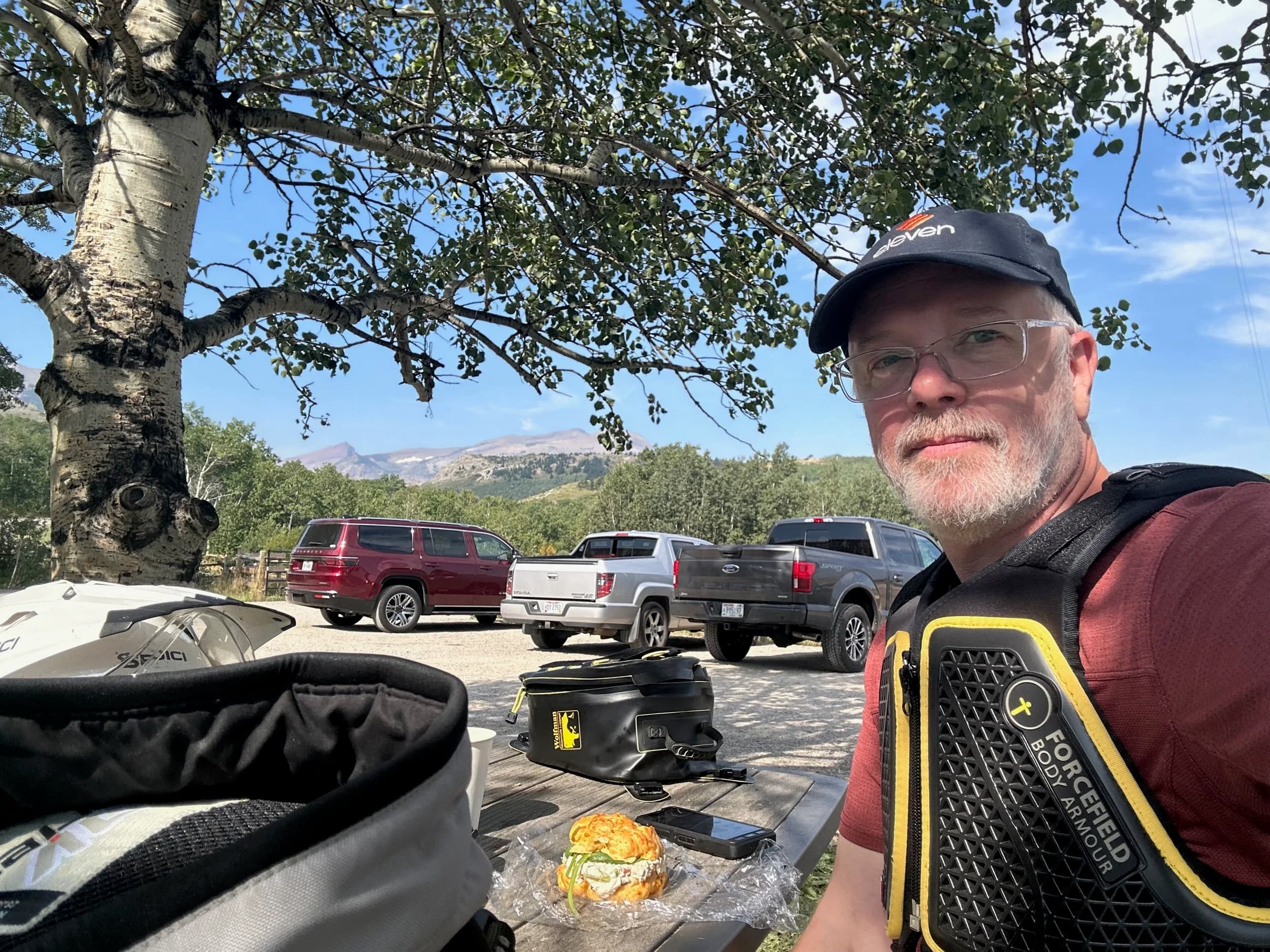 Trip Report: NW National Parks Loop
I left my job recently to take a much needed sabbatical and figure out what I’m doing next. A few weeks after my last day at work I embarked on what was to be a three week tour of NW-ish National Parks from Portland, to include Olympic, North Cascades, Glacier, Yellowstone, Grand Teton, Craters of the Moon, Lassen Volcanic, and Crater Lake.
I ended up missing Grand Tetons due to weather and I had to cut the trip short before I got to Lassen (family medical issue), so Lassen and Crater Lake remain unvisited.
Trip Dates: Sept 3 - Sept 16 (13 days)
Total Travel Miles: 3478 (does not include local miles for store runs, etc.)
Total Gallons of Gas Used: 82
Equipment: 2021 Benelli TRK502X Gaia GPS & Google Maps running on Sonim XP8 rugged Android phoneButler Motorcycle Maps (paper maps of best M/C roads in the country) iPhone 14 (main camera) Akaso Brave 7 helmet-mounted adventure camera Spot X satellite communicator and tracker Wolfman Luggage WP waterproof tank bag and saddle bags (no longer available) Watershed Colorado dry bag duffel (across the pillion seat) Kriega US-5 Drypack (tail bag) Kriega 3L hydration backpack (strapped to duffel, not worn)Marmot Ajax 2 tent Nemo hydrophobic down sleeping bag (non-mummy)Helinox ultralight cot MSR WhisperLite International stove
(Purchased in 1991 for my first moto trip: Detroit, MI to San Diego and back on an XT250)Gossamer Gear Bare Boxer bear-proof food canisters (two - one in each saddle bag)
Day 1 - Olympic National Park Date: Tuesday 9/3/2024
Destination: South Beach Campground, Olympic National Park
Travel Time: 4h 24m
Miles: 213Notes:
Planned to head west to Astoria then north from there, but left later than expected so headed up I-5 to US 12. I’ve driven/ridden that stretch of I-5 hundreds of times (starting in 1993). It’s boring and I hate it.
South Beach CG is first-come-first-served. I didn’t have issue getting a site. There is a long, tight loop of sites along the coastline, but I chose one of the sites further back near the bathrooms due to wind concerns. The bathroom building provided a sort of wind shelter for my site.
I used the heated grips on this leg; it was pretty chilly along the coast in the Olympic Peninsula. I almost didn’t install them, thinking I was being paranoid about the cold. I ended up using them a lot.
Day 2 - Ferry to Seattle / Burien Date: Wednesday 9/4/2024
Destination: Friend’s house in Burien, WA
Travel Time: 7h 30m
Miles: 199
Notes:
Slept well (thanks to Advil PM). I’ve not been sleeping well for more than a year. I’m really hoping to reset my sleep patterns with this trip. A good night’s sleep is one of my great joys and I feel like I’ve been robbed of that pleasure.
Used my Aeropress this morning for the first time ever. I’m hooked.
Headed up along US 101 through Port Angeles and then down to the Southworth ferry terminal near Port Orchard. Ferried across to Fauntleroy, which is just a few miles north my friend’s house in Burien. I’m always surprised at how long it takes to get from the Olympic Peninsula to the east side of Puget Sound (Seattle, etc.). With the ferry crossing (I love ferries) it took seven and a half hours to go 200 miles.
Discovered at my first stop of the day (just up 101 at the Kalaloch Campground, stopped to refill water) that the battery is quite weak and won’t start the bike if you leave the ignition on for even two minutes without the motor running. This would become a theme for the next few days. Fortunately, I have a jumper box and a permanent jump harness wired to the battery so jump starts are a quick operation.
Had a good evening with old friends.
Day 3 - North Cascades via Mountain Loop RoadDate: Thursday 9/5/2024
Destination: Newhalem Campground, North Cascades National Park
Travel Time: 4h 30m
Miles: 146Notes:
Slept well, on the couch. No pills needed.
I realized yesterday that my summer riding gloves (Rev’It Dune) were a size (or two) too small. Rev’It gloves fit really tight and I feel like I can never get it quite right. And yet, I love them. So, I stopped at a Cycle Gear in Bellevue to pick up something summer weight (Dirt 3) that fit better. They’re better, but maybe still one size too small. Such is life.
From Bellevue, I rode north and took the Mountain Loop Hwy then on up north to North Cascades. It was a hot ride. Still summer.
A small section of the Mountain Loop Road is dirt/gravel, which I didn’t realize. No biggie. Was just surprised (clearly I didn’t study my maps closely enough). When riding solo on a bike that weighs over 500 lbs., I tend to avoid planning much off-pavement riding. That’s what my DR-Z is for.
Day 4 - Newport, Washington via Winthrop Date: Friday 9/6/2024
Destination: Golden Spur Motor Inn, Newport, Washington
Travel Time: 8h
Miles: 308
Notes:
Slept just ok, even with Advil PM.
Pretty ride through North Cascades National Park and Colville National Forest. Didn’t do any backroads or hikes. Discovered (new to me) the town of Winthrop. Stopped for coffee at Sheri’s and resupplied on freeze-dried food at Cascades Outdoor Store.
The town of Newport is almost nothing, but, inexplicably, there’s an amazing restaurant (Brownell’s Place). Had dinner and a few ciders. Met and chatted with the owner/chef (she’s great). Listened to some live music. Then back to the motel.
Day 5 - New Battery in Kalispell Date: Saturday 9/7/2024
Destination: West Glacier KOA, West Glacier, MT
Travel Time: 8h 7m
Miles: 293
Notes:
Slept well on motel bed (on sleeping bag, not in the sheets). Another hot one.
Discovered that the water pump seal leaks oil. A quick post in the TRK Facebook group revealed that this is a common problem on this bike, and and easy fix. It’s apparently just a bad o-ring.
Battery has been getting continuously worse, and now requires I jump start the bike about every other start. Google Maps to the rescue: directions to the Batteries Plus in Kalispell, please. They don’t have an Odyssey AGM in the right size; the Duracell will have to do. (It’s been great.)
I set up camp at the West Glacier KOA, which will be my base for a few days. KOAs are their own little world. Very strange. Not really my thing, but the on-site laundry was handy.
After setting up camp I opened a cider and used the iPad to book a vehicle reservation for the next day to ride Going to the Sun Road, which I really wanted to do.
Day 6 - Going to the Sun RoadDate: Sunday 9/8/2024
Destination: Local Ride: West Glacier, Going to the Sun Road, Saint Mary, East Glacier
Travel Time: 5h 35m
Miles: 142Notes:
Quick breakfast and gas up in West Glacier before entering Going to the Sun Road.
Going to the Sun Road was stunning. This was the first point in the trip where I had tingles and was giddy at what I was seeing.
Took a very short hike along Saint Mary Lake. Again, I was beside myself with the beauty.
Lunch at the general store in Kiowa.
The rest of the ride back after East Glacier was meh, but I just kept thinking about how amazing what I’d seen in the morning had been.
Dinner at the KOA. Tacos from a cart (ok / not great, and a very weird guacamole) and a few glasses of wine from another cart. I asked about the guac and it turns out they make it in a food processor. Come on, people.
Day 7 - Ride to BozemanDate: Monday 9/9/2024
Destination: Friend’s house in Bozeman, Montana
Travel Time: ~ 8h (Gaia crashed near the end of the trip, but before getting to Bozeman)
Miles: ~ 400Notes:
Slept poorly again. No pills this time. Took some photos of my soft luggage setup to answer some questions in the TRK502X Facebook group. The saddle bags are from Wolfman Luggage, but I don’t think they make this waterproof line anymore. I use a duffel dry bag from Watershed across the top. A heat shield protects the side bag from exhaust heat.
Hazy, smoky ride most of the way. Very windy in places. This is where I first really started to feel how underpowered the TRK502 is. Really struggled in places.
Developed an engine-speed-sensitive squeak or rattle. Sounds like when a heat shield vibrates in resonance with engine vibration. Discovered that it’s a missing crash bar mounting bolt allowing the crash bar to rub against the frame.
Also noticed that there’s a resonant oscillation at speed that feels like the chain going bad (like it’s stretching unevenly).
First of several nights at a friend’s house in Bozeman (which, it turns out, is a pretty cool town). And there’s a hot tub…
Day 8 - Bike Maintenance & Hyalite ReservoirDate: Tuesday 9/10/2024
Destination: Local Ride: Hyalite Reservoir
Travel Time: not recorded
Miles: not recordedNotes:
Woke up to a smoky sunrise. I had the best night’s sleep I’ve had in years. This is was the whole point of this trip: to untangle my burnout and reclaim sleep as one of my joys. I wrote about it in my journal when I woke up. I hope this wasn’t a fluke.
Planned to replace the bolt that rattled loose from the crash bar, but instead discovered that it had actually severed off at the mount point. No fixing that on the road. Adjusted chain and moved on.
Lunch at Mountains Walking Brewery in Bozeman.
Rode up to Hyalite Reservoir. Pretty ride. Smoky still.
Soaked in hot tub after dinner.
Day 9 - North Yellowstone LoopDate: Wednesday 9/11/2024
Destination: Northern loop through Yellowstone National Park
Travel Time: 9h 36m
Miles: 272Notes:
Did a day trip from Bozeman down through the northern loop in Yellowstone, entering at Mammoth and taking the scenic route through Paradise Valley.
Saw elk, coyotes (I think), buffalo, and pronghorn.
Pretty ride, but cold in places. Used heated grips again.
Rode the loop through Mammoth Hot Springs (see video) at the end.
Coffee at Tumbleweed Bookstore & Cafe in Gardiner. I kind of dig Gardiner. Good vibe.
Had dinner at Mountains Walking Brewing. Rain and wind started. Lights flickered. Waited for rain to stop before riding back to the house.
Power out at the house due to high winds. This does not bode well for tomorrow.
Day 10 - Winter Weather in the ParksDate: Thursday 9/12/2024
Destination: Grand Teton National Park via West Yellowstone Pocatello, Idaho
Travel Time: 5h 40m
Miles: 201Notes:
Today was supposed to be a gorgeous ride through Yellowstone into Grand Teton National Park, and camping at Signal Mountain CG in the park. The weather had other ideas. It was pouring rain (and cold) all the way to West Yellowstone from Bozeman. By the time I got to West Yellowstone I was getting severe winter weather warnings on my phone calling for up to 3 (three!!) inches of snow accumulating in the high passes in the park. It’s bad enough in a car, but that’s a disaster waiting to happen on a motorcycle.
I parked my butt at Mountain Mama’s Cafe in West Yellowstone to warm up / dry off and decide what to do. I almost had myself convinced to push through when I realized that, even if I made it to the campground ok, I’d be setting up camp in the rain and I’d likely be miserable all night. Grand Teton would have to wait.
From West Yellowstone it’s easy to bail west into Idaho and get away from the park weather and elevations. So that’s what I did. It was not a pleasant ride, though. I was in torrential downpours all the way to Idaho Falls.
Arriving in Idaho Falls, I was exhausted and sure I could just find a room for the night. I dropped the bike at a roundabout (short-legged it coming to a stop; I knew it was going so I just rolled away). Guy behind me helped me pick it up. Then, there were no rooms because it was move in week for the two universities there (U of I, ISU). This would become a recurring theme.
I rode further to Blackfoot. Still no rooms.
I called ahead to Pocatello and got a room at a Red Lion there. I was never so happy to be off the bike.
No pictures this day. I couldn’t even get the action camera to turn on.
Day 11 - Craters of the Moon and EBR-1Date: Friday 9/13/2024
Destination: Craters of the Moon National Monument
Travel Time: 4h 20m
Miles: 124
Notes:
I wasn’t sure what my destination would be today but my plan was to do a little nuclear tourism, see Craters of the Moon, and then go somewhere from there. My schedule and day-plan was thrown off by missing Grand Teton National Park and spending a night in Pocatello, which was not on the itinerary at all.
Stopped in Atomic City. Not sure why; I was under the impression that Atomic City was the first city lit by nuclear engergy, but it was practically a ghost town. There are a few houses there, but as far as I could tell all of the business were shuttered. Except, maybe, for the race track; that looked like it might still get used.
Arco, it turns out, is the city celebrated as the first in the world to be lit by nuclear energy. Nothing special about the town, but they do a nice job of making City Hall photo-worthy.
Between Atomic City and Arco is EBR-1 (Experimental Breeder Reactor I) which was the world’s first breeder reactor. The EBR-1 exhibit was closed for the season, but in the lot next to it were some really interesting experimental nuclear heat-transfer jet engines that never made it out of the experimental phase (probably a good thing).
Craters of the Moon is pretty small. If you don’t do any of the walks, it’s literally just a 30 minute road loop. Still, it was an unexpected surprise and delight. I had no idea what to expect but I was positively chuffed at the experience. I noticed that the campground had open sites so I inquired at the entry booth. As luck would have it, the whole campground is first come / first serve. I decided to set up for the night. It’s good to be done early and have some time to read and not stress about making distance.
Day 12 - New Chain in Twin FallsDate: Saturday 9/14/2024
Destination: Battle Mountain, Nevada
Travel Time: 8h 52m
Miles: 335
Notes:
Beautiful morning in Craters of the Moon. While I was breaking camp a parade of classic cars came into the park to drive the loop. I got a picture of one Pontiac down the road in Carey at a gas station.
Carey ended up being an unplanned fork in the road for me. I discovered this morning that my chain was indeed stretching unevenly, and the oscillation I was feeling and hearing was the chain hum changing from a “loose” hum to a “tight” hum rapidly as the tight spot moved around the sprockets. I was supposed to continue west to Mountain Home and then south from there into Nevada. A very scenic route, according to my Butler map. But, between camp and the gas station I got pretty paranoid about the chain snapping at high speed, which, worst case, could lead to a fatal crash.
So I called ahead to a few motorcycle dealers in Mountain Home (on my planned route) to see if they could take me in and replace the chain. No dice. This is the downside of having an obscure motorcycle from an obscure marque - no one wants to work on it. Making matters worse this is an Italian-designed bike built in China, a fact which causes many people to lose the ability to think clearly. “It’s Chinese junk!” Not so. Next.
With Mountain Home out, I tried Twin Falls. My first call was to Adventure Motorsports, and the service manager there took me in with no hesitation. “How soon can you be here?” I didn’t get his name, but my hat’s off to him and his one tech working furiously on a Saturday to beat the 3pm closing time. He said during high season, they get about 15-20 out of town travelers per week who need something done, and they take them all in. I love to hear stuff like this. This shop is in it for the community. They have a nice showroom, too.
With a quality new chain installed, I got a burrito and a MexiCoke at a Mexican place and went on my way. I made it to Battle Mountain, NV, where I decide to get a room. Tomorrow I rejoin my planned scenic route. Day 13 - Desert Mountains in NV, CADate: Sunday 9/15/2024
Destination: Grizzly Campground, Lake Davis (near Portola, CA)
Travel Time: 7h
Miles: 307
Notes:
I love the northern Nevada landscape, and today’s ride didn’t disappoint. US Highway 50 is apparently known as “The Loneliest Highway” but everyone knows about it, so it’s not very lonely. However, after leaving Austin, NV headed west you can take Nevada Highway 722, which dips to the south and follows the old US 50 route. It was completely empty and the twisties through the passes were fun. Highly recommended.
Stopped in Fallon for gas and to find a Micro SD card for the action camera. Walmart to the rescue.
After Reno, I crossed into California and, I swear, it looks different. Norther California desert mountains are so beautiful.
Camped at a nearly empty campground on Lake Davis (very end of the season). The host warned me rain was coming tomorrow.
Day 14 - Unplanned Return HomeDate: Monday 9/16/2024
Destination: Summit Lake Campground, Lassen Volcanic National Park Portland, Oregon (Home)
Travel Time: 10h 32m
Miles: 538Notes:
Last week, my mom went into the hospital for a fairly routine procedure. My brother went to Michigan to help out, as needed, and he went back home to Arizona after she returned home and everything seemed settled.
This morning, while having coffee, I got a call that she’d gone back into the hospital with something that may or may not have been related to the procedure. It seemed like maybe things were ok, but maybe not.
I decided the best thing to do was head home so that I was near an airport if I needed to fly out to Michigan to help out.
I packed up camp and headed up US 395 toward home, via Klamath Falls. It was a pretty ride, but, once again, I found myself in rain most of the way to Klamath Falls.
I was pretty beat by the time I got to Klamath Falls and figured I’d just find a hotel room, get a hot shower, and finish the ride tomorrow.
But, once again, it was move-in week for the local university. Holiday Inn Express had a single room for $395. No thanks. Onward.
I never hit rain again after Klamath Falls, and after turning west onto Oregon Hwy 58 and starting to lose elevation into the Willamette Valley, the temperature starting rising, which was welcome.
Once I reached Eugene, there was no point in not just going all the way home, so that’s what I did.
I got two pictures: one at camp before the call, and one at my last gas stop, an hour and twenty minutes from home, with the moon rising.
A nice side effect of my early return home is that I was home for my birthday (tomorrow), so I had dinner with my kids and my wife, which was lovely.
I did end up flying to Michigan the next day, and was there for a bit. The best part? I got to make some meals for my mom and step dad. Everything seems ok with my mom for now.
Grand Teton, Lassen, and Crater Lake will be there, and now I have an excuse for another trip in the future.