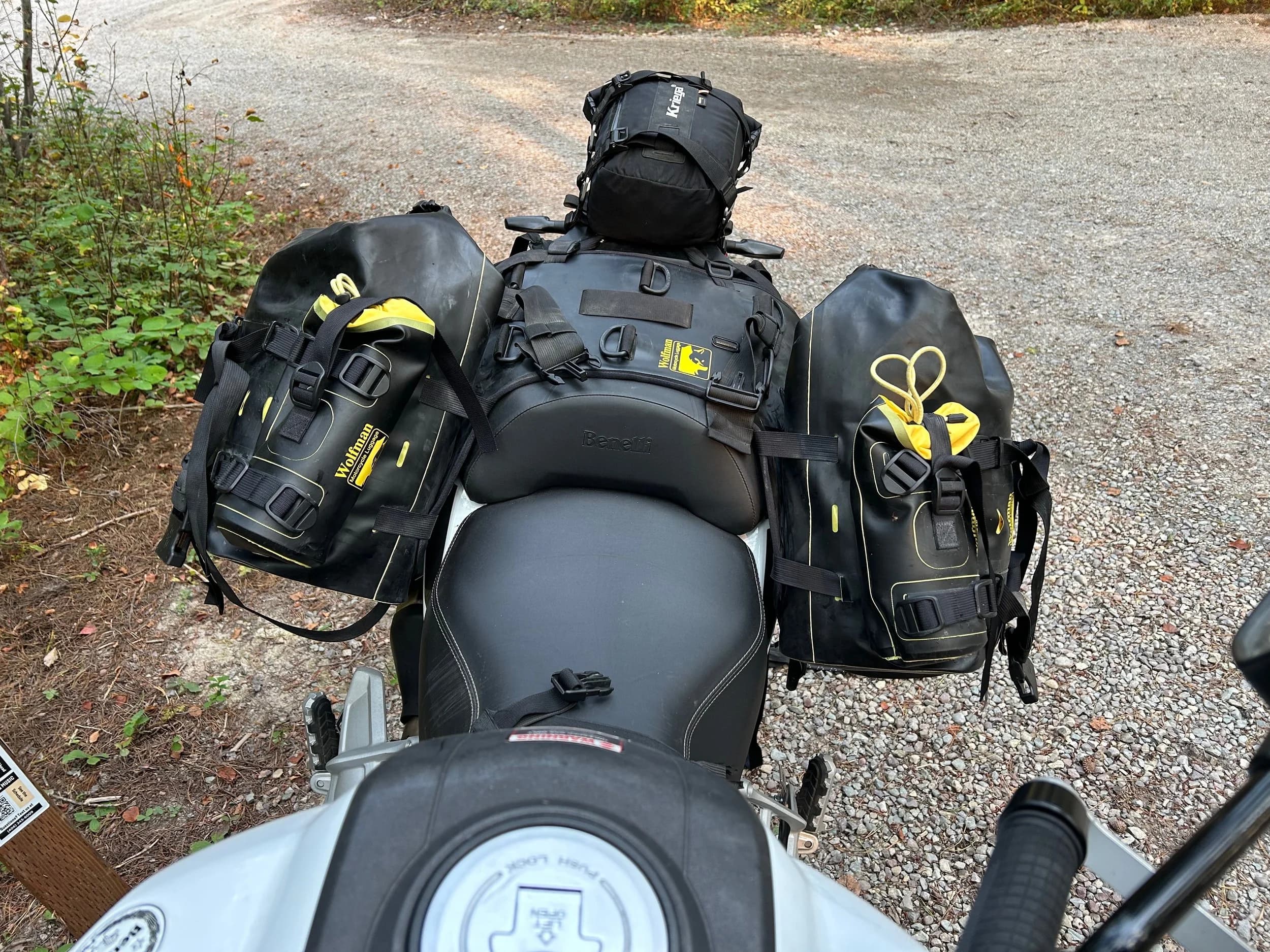 Trip Report: NW National Parks Loop
I left my job recently to take a much needed sabbatical and figure out what I’m doing next. A few weeks after my last day at work I embarked on what was to be a three week tour of NW-ish National Parks from Portland, to include Olympic, North Cascades, Glacier, Yellowstone, Grand Teton, Craters of the Moon, Lassen Volcanic, and Crater Lake.
I ended up missing Grand Tetons due to weather and I had to cut the trip short before I got to Lassen (family medical issue), so Lassen and Crater Lake remain unvisited.
Trip Dates: Sept 3 - Sept 16 (13 days)
Total Travel Miles: 3478 (does not include local miles for store runs, etc.)
Total Gallons of Gas Used: 82
Equipment: 2021 Benelli TRK502X Gaia GPS & Google Maps running on Sonim XP8 rugged Android phoneButler Motorcycle Maps (paper maps of best M/C roads in the country) iPhone 14 (main camera) Akaso Brave 7 helmet-mounted adventure camera Spot X satellite communicator and tracker Wolfman Luggage WP waterproof tank bag and saddle bags (no longer available) Watershed Colorado dry bag duffel (across the pillion seat) Kriega US-5 Drypack (tail bag) Kriega 3L hydration backpack (strapped to duffel, not worn)Marmot Ajax 2 tent Nemo hydrophobic down sleeping bag (non-mummy)Helinox ultralight cot MSR WhisperLite International stove
(Purchased in 1991 for my first moto trip: Detroit, MI to San Diego and back on an XT250)Gossamer Gear Bare Boxer bear-proof food canisters (two - one in each saddle bag)
Day 1 - Olympic National Park Date: Tuesday 9/3/2024
Destination: South Beach Campground, Olympic National Park
Travel Time: 4h 24m
Miles: 213Notes:
Planned to head west to Astoria then north from there, but left later than expected so headed up I-5 to US 12. I’ve driven/ridden that stretch of I-5 hundreds of times (starting in 1993). It’s boring and I hate it.
South Beach CG is first-come-first-served. I didn’t have issue getting a site. There is a long, tight loop of sites along the coastline, but I chose one of the sites further back near the bathrooms due to wind concerns. The bathroom building provided a sort of wind shelter for my site.
I used the heated grips on this leg; it was pretty chilly along the coast in the Olympic Peninsula. I almost didn’t install them, thinking I was being paranoid about the cold. I ended up using them a lot.
Day 2 - Ferry to Seattle / Burien Date: Wednesday 9/4/2024
Destination: Friend’s house in Burien, WA
Travel Time: 7h 30m
Miles: 199
Notes:
Slept well (thanks to Advil PM). I’ve not been sleeping well for more than a year. I’m really hoping to reset my sleep patterns with this trip. A good night’s sleep is one of my great joys and I feel like I’ve been robbed of that pleasure.
Used my Aeropress this morning for the first time ever. I’m hooked.
Headed up along US 101 through Port Angeles and then down to the Southworth ferry terminal near Port Orchard. Ferried across to Fauntleroy, which is just a few miles north my friend’s house in Burien. I’m always surprised at how long it takes to get from the Olympic Peninsula to the east side of Puget Sound (Seattle, etc.). With the ferry crossing (I love ferries) it took seven and a half hours to go 200 miles.
Discovered at my first stop of the day (just up 101 at the Kalaloch Campground, stopped to refill water) that the battery is quite weak and won’t start the bike if you leave the ignition on for even two minutes without the motor running. This would become a theme for the next few days. Fortunately, I have a jumper box and a permanent jump harness wired to the battery so jump starts are a quick operation.
Had a good evening with old friends.
Day 3 - North Cascades via Mountain Loop RoadDate: Thursday 9/5/2024
Destination: Newhalem Campground, North Cascades National Park
Travel Time: 4h 30m
Miles: 146Notes:
Slept well, on the couch. No pills needed.
I realized yesterday that my summer riding gloves (Rev’It Dune) were a size (or two) too small. Rev’It gloves fit really tight and I feel like I can never get it quite right. And yet, I love them. So, I stopped at a Cycle Gear in Bellevue to pick up something summer weight (Dirt 3) that fit better. They’re better, but maybe still one size too small. Such is life.
From Bellevue, I rode north and took the Mountain Loop Hwy then on up north to North Cascades. It was a hot ride. Still summer.
A small section of the Mountain Loop Road is dirt/gravel, which I didn’t realize. No biggie. Was just surprised (clearly I didn’t study my maps closely enough). When riding solo on a bike that weighs over 500 lbs., I tend to avoid planning much off-pavement riding. That’s what my DR-Z is for.
Day 4 - Newport, Washington via Winthrop Date: Friday 9/6/2024
Destination: Golden Spur Motor Inn, Newport, Washington
Travel Time: 8h
Miles: 308
Notes:
Slept just ok, even with Advil PM.
Pretty ride through North Cascades National Park and Colville National Forest. Didn’t do any backroads or hikes. Discovered (new to me) the town of Winthrop. Stopped for coffee at Sheri’s and resupplied on freeze-dried food at Cascades Outdoor Store.
The town of Newport is almost nothing, but, inexplicably, there’s an amazing restaurant (Brownell’s Place). Had dinner and a few ciders. Met and chatted with the owner/chef (she’s great). Listened to some live music. Then back to the motel.
Day 5 - New Battery in Kalispell Date: Saturday 9/7/2024
Destination: West Glacier KOA, West Glacier, MT
Travel Time: 8h 7m
Miles: 293
Notes:
Slept well on motel bed (on sleeping bag, not in the sheets). Another hot one.
Discovered that the water pump seal leaks oil. A quick post in the TRK Facebook group revealed that this is a common problem on this bike, and and easy fix. It’s apparently just a bad o-ring.
Battery has been getting continuously worse, and now requires I jump start the bike about every other start. Google Maps to the rescue: directions to the Batteries Plus in Kalispell, please. They don’t have an Odyssey AGM in the right size; the Duracell will have to do. (It’s been great.)
I set up camp at the West Glacier KOA, which will be my base for a few days. KOAs are their own little world. Very strange. Not really my thing, but the on-site laundry was handy.
After setting up camp I opened a cider and used the iPad to book a vehicle reservation for the next day to ride Going to the Sun Road, which I really wanted to do.
Day 6 - Going to the Sun RoadDate: Sunday 9/8/2024
Destination: Local Ride: West Glacier, Going to the Sun Road, Saint Mary, East Glacier
Travel Time: 5h 35m
Miles: 142Notes:
Quick breakfast and gas up in West Glacier before entering Going to the Sun Road.
Going to the Sun Road was stunning. This was the first point in the trip where I had tingles and was giddy at what I was seeing.
Took a very short hike along Saint Mary Lake. Again, I was beside myself with the beauty.
Lunch at the general store in Kiowa.
The rest of the ride back after East Glacier was meh, but I just kept thinking about how amazing what I’d seen in the morning had been.
Dinner at the KOA. Tacos from a cart (ok / not great, and a very weird guacamole) and a few glasses of wine from another cart. I asked about the guac and it turns out they make it in a food processor. Come on, people.
Day 7 - Ride to BozemanDate: Monday 9/9/2024
Destination: Friend’s house in Bozeman, Montana
Travel Time: ~ 8h (Gaia crashed near the end of the trip, but before getting to Bozeman)
Miles: ~ 400Notes:
Slept poorly again. No pills this time. Took some photos of my soft luggage setup to answer some questions in the TRK502X Facebook group. The saddle bags are from Wolfman Luggage, but I don’t think they make this waterproof line anymore. I use a duffel dry bag from Watershed across the top. A heat shield protects the side bag from exhaust heat.
Hazy, smoky ride most of the way. Very windy in places. This is where I first really started to feel how underpowered the TRK502 is. Really struggled in places.
Developed an engine-speed-sensitive squeak or rattle. Sounds like when a heat shield vibrates in resonance with engine vibration. Discovered that it’s a missing crash bar mounting bolt allowing the crash bar to rub against the frame.
Also noticed that there’s a resonant oscillation at speed that feels like the chain going bad (like it’s stretching unevenly).
First of several nights at a friend’s house in Bozeman (which, it turns out, is a pretty cool town). And there’s a hot tub…
Day 8 - Bike Maintenance & Hyalite ReservoirDate: Tuesday 9/10/2024
Destination: Local Ride: Hyalite Reservoir
Travel Time: not recorded
Miles: not recordedNotes:
Woke up to a smoky sunrise. I had the best night’s sleep I’ve had in years. This is was the whole point of this trip: to untangle my burnout and reclaim sleep as one of my joys. I wrote about it in my journal when I woke up. I hope this wasn’t a fluke.
Planned to replace the bolt that rattled loose from the crash bar, but instead discovered that it had actually severed off at the mount point. No fixing that on the road. Adjusted chain and moved on.
Lunch at Mountains Walking Brewery in Bozeman.
Rode up to Hyalite Reservoir. Pretty ride. Smoky still.
Soaked in hot tub after dinner.
Day 9 - North Yellowstone LoopDate: Wednesday 9/11/2024
Destination: Northern loop through Yellowstone National Park
Travel Time: 9h 36m
Miles: 272Notes:
Did a day trip from Bozeman down through the northern loop in Yellowstone, entering at Mammoth and taking the scenic route through Paradise Valley.
Saw elk, coyotes (I think), buffalo, and pronghorn.
Pretty ride, but cold in places. Used heated grips again.
Rode the loop through Mammoth Hot Springs (see video) at the end.
Coffee at Tumbleweed Bookstore & Cafe in Gardiner. I kind of dig Gardiner. Good vibe.
Had dinner at Mountains Walking Brewing. Rain and wind started. Lights flickered. Waited for rain to stop before riding back to the house.
Power out at the house due to high winds. This does not bode well for tomorrow.
Day 10 - Winter Weather in the ParksDate: Thursday 9/12/2024
Destination: Grand Teton National Park via West Yellowstone Pocatello, Idaho
Travel Time: 5h 40m
Miles: 201Notes:
Today was supposed to be a gorgeous ride through Yellowstone into Grand Teton National Park, and camping at Signal Mountain CG in the park. The weather had other ideas. It was pouring rain (and cold) all the way to West Yellowstone from Bozeman. By the time I got to West Yellowstone I was getting severe winter weather warnings on my phone calling for up to 3 (three!!) inches of snow accumulating in the high passes in the park. It’s bad enough in a car, but that’s a disaster waiting to happen on a motorcycle.
I parked my butt at Mountain Mama’s Cafe in West Yellowstone to warm up / dry off and decide what to do. I almost had myself convinced to push through when I realized that, even if I made it to the campground ok, I’d be setting up camp in the rain and I’d likely be miserable all night. Grand Teton would have to wait.
From West Yellowstone it’s easy to bail west into Idaho and get away from the park weather and elevations. So that’s what I did. It was not a pleasant ride, though. I was in torrential downpours all the way to Idaho Falls.
Arriving in Idaho Falls, I was exhausted and sure I could just find a room for the night. I dropped the bike at a roundabout (short-legged it coming to a stop; I knew it was going so I just rolled away). Guy behind me helped me pick it up. Then, there were no rooms because it was move in week for the two universities there (U of I, ISU). This would become a recurring theme.
I rode further to Blackfoot. Still no rooms.
I called ahead to Pocatello and got a room at a Red Lion there. I was never so happy to be off the bike.
No pictures this day. I couldn’t even get the action camera to turn on.
Day 11 - Craters of the Moon and EBR-1Date: Friday 9/13/2024
Destination: Craters of the Moon National Monument
Travel Time: 4h 20m
Miles: 124
Notes:
I wasn’t sure what my destination would be today but my plan was to do a little nuclear tourism, see Craters of the Moon, and then go somewhere from there. My schedule and day-plan was thrown off by missing Grand Teton National Park and spending a night in Pocatello, which was not on the itinerary at all.
Stopped in Atomic City. Not sure why; I was under the impression that Atomic City was the first city lit by nuclear engergy, but it was practically a ghost town. There are a few houses there, but as far as I could tell all of the business were shuttered. Except, maybe, for the race track; that looked like it might still get used.
Arco, it turns out, is the city celebrated as the first in the world to be lit by nuclear energy. Nothing special about the town, but they do a nice job of making City Hall photo-worthy.
Between Atomic City and Arco is EBR-1 (Experimental Breeder Reactor I) which was the world’s first breeder reactor. The EBR-1 exhibit was closed for the season, but in the lot next to it were some really interesting experimental nuclear heat-transfer jet engines that never made it out of the experimental phase (probably a good thing).
Craters of the Moon is pretty small. If you don’t do any of the walks, it’s literally just a 30 minute road loop. Still, it was an unexpected surprise and delight. I had no idea what to expect but I was positively chuffed at the experience. I noticed that the campground had open sites so I inquired at the entry booth. As luck would have it, the whole campground is first come / first serve. I decided to set up for the night. It’s good to be done early and have some time to read and not stress about making distance.
Day 12 - New Chain in Twin FallsDate: Saturday 9/14/2024
Destination: Battle Mountain, Nevada
Travel Time: 8h 52m
Miles: 335
Notes:
Beautiful morning in Craters of the Moon. While I was breaking camp a parade of classic cars came into the park to drive the loop. I got a picture of one Pontiac down the road in Carey at a gas station.
Carey ended up being an unplanned fork in the road for me. I discovered this morning that my chain was indeed stretching unevenly, and the oscillation I was feeling and hearing was the chain hum changing from a “loose” hum to a “tight” hum rapidly as the tight spot moved around the sprockets. I was supposed to continue west to Mountain Home and then south from there into Nevada. A very scenic route, according to my Butler map. But, between camp and the gas station I got pretty paranoid about the chain snapping at high speed, which, worst case, could lead to a fatal crash.
So I called ahead to a few motorcycle dealers in Mountain Home (on my planned route) to see if they could take me in and replace the chain. No dice. This is the downside of having an obscure motorcycle from an obscure marque - no one wants to work on it. Making matters worse this is an Italian-designed bike built in China, a fact which causes many people to lose the ability to think clearly. “It’s Chinese junk!” Not so. Next.
With Mountain Home out, I tried Twin Falls. My first call was to Adventure Motorsports, and the service manager there took me in with no hesitation. “How soon can you be here?” I didn’t get his name, but my hat’s off to him and his one tech working furiously on a Saturday to beat the 3pm closing time. He said during high season, they get about 15-20 out of town travelers per week who need something done, and they take them all in. I love to hear stuff like this. This shop is in it for the community. They have a nice showroom, too.
With a quality new chain installed, I got a burrito and a MexiCoke at a Mexican place and went on my way. I made it to Battle Mountain, NV, where I decide to get a room. Tomorrow I rejoin my planned scenic route. Day 13 - Desert Mountains in NV, CADate: Sunday 9/15/2024
Destination: Grizzly Campground, Lake Davis (near Portola, CA)
Travel Time: 7h
Miles: 307
Notes:
I love the northern Nevada landscape, and today’s ride didn’t disappoint. US Highway 50 is apparently known as “The Loneliest Highway” but everyone knows about it, so it’s not very lonely. However, after leaving Austin, NV headed west you can take Nevada Highway 722, which dips to the south and follows the old US 50 route. It was completely empty and the twisties through the passes were fun. Highly recommended.
Stopped in Fallon for gas and to find a Micro SD card for the action camera. Walmart to the rescue.
After Reno, I crossed into California and, I swear, it looks different. Norther California desert mountains are so beautiful.
Camped at a nearly empty campground on Lake Davis (very end of the season). The host warned me rain was coming tomorrow.
Day 14 - Unplanned Return HomeDate: Monday 9/16/2024
Destination: Summit Lake Campground, Lassen Volcanic National Park Portland, Oregon (Home)
Travel Time: 10h 32m
Miles: 538Notes:
Last week, my mom went into the hospital for a fairly routine procedure. My brother went to Michigan to help out, as needed, and he went back home to Arizona after she returned home and everything seemed settled.
This morning, while having coffee, I got a call that she’d gone back into the hospital with something that may or may not have been related to the procedure. It seemed like maybe things were ok, but maybe not.
I decided the best thing to do was head home so that I was near an airport if I needed to fly out to Michigan to help out.
I packed up camp and headed up US 395 toward home, via Klamath Falls. It was a pretty ride, but, once again, I found myself in rain most of the way to Klamath Falls.
I was pretty beat by the time I got to Klamath Falls and figured I’d just find a hotel room, get a hot shower, and finish the ride tomorrow.
But, once again, it was move-in week for the local university. Holiday Inn Express had a single room for $395. No thanks. Onward.
I never hit rain again after Klamath Falls, and after turning west onto Oregon Hwy 58 and starting to lose elevation into the Willamette Valley, the temperature starting rising, which was welcome.
Once I reached Eugene, there was no point in not just going all the way home, so that’s what I did.
I got two pictures: one at camp before the call, and one at my last gas stop, an hour and twenty minutes from home, with the moon rising.
A nice side effect of my early return home is that I was home for my birthday (tomorrow), so I had dinner with my kids and my wife, which was lovely.
I did end up flying to Michigan the next day, and was there for a bit. The best part? I got to make some meals for my mom and step dad. Everything seems ok with my mom for now.
Grand Teton, Lassen, and Crater Lake will be there, and now I have an excuse for another trip in the future.