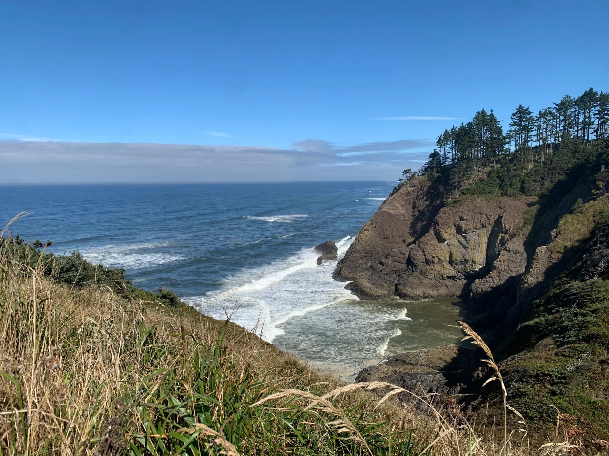 Trip Report: Portland to Olympic Peninsula to Orcas Island
If you follow me on Instagram, you know I purchased a 2021 Benelli TRK502X in July. I just completed my first overnight trip with the new Benelli, doing 7 nights / 8 days from Portland, up the Olympic Peninsula, over to Bellingham and then finally to Orcas Island.
The plan was to camp most or all nights until my last two nights on Orcas, where I had a small waterfront cottage rented right in Orcas Village, where the ferry lands. After three nights of camping, however, I realized I can’t really do the “thin air pad on the ground” thing anymore (I’d be 50 in a week, after all!). My back was killing me and I was not sleeping well, making the following day’s ride less enjoyable at best, and probably also less safe.
So, instead of 5 nights of camping, I did three and then found a cheap motel in Port Angeles, figuring I’d camp the next night and then do my two nights in the cottage. As it happened, most of the next day was rain and the forecast was rain all night and into the morning, so I ended up in a hotel in Bellingham to avoid setting up and breaking down camp in the rain. I can do it. Have done it. But if money is no object and there is lodging available, why be miserable?
The route I planned was intended to get me familiar with the TRK’s manners while allowing for the fact that I’d be riding solo and really didn’t want to get into trouble that I couldn’t get myself out of. The 502X, despite being a 500cc bike, is not light. Curb weight is listed as 518 lbs (dry is 470). So, I favored two lane highways, but included some backcountry single lane roads that were a mix of pavement and gravel.
Here’s my trip report. Day 1Planned / Actual Destination: Cape Disappointment State Park
Planned / Actual Accommodation: Camping
Planned / Actual Miles: 201 / 212
Planned Route: Tigard to Seaside via the Nestucca River Backcountry Byway; Seaside to Cape Disappointment via US 101.
Route NotesI let Google guide me to Carlton from Tigard (home base). On Gaia GPS, I had planned a route that followed the Nestucca River Backcountry Byway from Carlton to Beaver. Unfortunately, there was a detour after McGuire Reservoir (the body of water at the left edge of the right third of the map above) that took me well south down to Bell Mountain along Bald Mountain Rd before heading back north again and rejoining the Nestucca River Rd near Thune Mouintain. Basically, I missed at least half of the scenic route I was hoping for. I wasn’t sure how far the closure went on Nestucca River Rd, and I was still getting the hang of using Gaia to both see where I was, and plan where I wanted to go…so I just followed the signs for the detour. The detour was nice, but it wasn’t the Nestucca River . Most of the route was paved single lane forest road, with a small section of gravel thrown in before the detour.
Once to Beaver, I just rode south on 101 until I saw the signs for Pacific City. Lunch at Pelican Brewery. (I’m not a fan of their new orange grate picnic table outdoor seating.)
After lunch, I rode straight up 101 through Astoria and across to Ilwaco, where I had a reservation to camp at Cape Disappointment. Great spot, right up against the beach (with some trees and brush to break the wind). Camp NotesCape Disappointment was filled mostly with campers pulled by pickup trucks, and my site was nestled between two of them. Most people were friendly. The guy on the north side came over right away to ask about the bike. He’d never seen or heard of Benelli. The guy on the south side came over several times. It’s like he kept looking for excuses to come over and talk more. He even offered me dinner (red beans and rice, with sausage). I accepted. The next morning, he came over with pictures of places I should see in Olympic National Park. The wife of the guy on the north side came over just before I departed for the day’s travels. “Looks like a lot of fun. Nice bike. Reminds me of when we used to backpack. Now we have this thing,” (she gestured to her trailer).
The site itself was great. It was wooded, and sheltered from the beach winds with a thin band of trees and brush, plus a wall of driftwood you had to navigate through and over to get to the beach. The beach itself was gorgeous. Gear NotesI’d read that my trusty MSR Whisperlite Internationale (purchased in 1991) can run on unleaded gasoline just as easily as white gas. Since this kind of moto touring is about going as light and simply as possible, I figured I’d just run unleaded gas instead of bringing white gas. This way, I’d have 1.5 liters of spare gas plus whatever was in my stove bottle in the event that I ran out of gas on the road. Seemed like a great idea.
The reality, as I found out, is that gasoline burns very dirty compared to white gas. It lit, no problem, but the stove was left covered in black soot after a single burn and everything ends up smelling like gasoline. I never realized how much I’d want to smell white gas. So, next trip I’ll ditch the gasoline and go back to white gas.
Also, I threw out my deodorant and body soap before bed. Because I’m using soft bags (not hard aluminum cases) all of my food, toothpaste, and other smelly items need to fit into a small bear canister that fits inside one of my soft bags (keeps rodents out, even if there are no bears). To save space, the stove needs to fit in the bear canister, too. The deodorant and soap simply didn’t fit. So, off they went. Besides, I use Dr. Bronner’s as my dish soap. If I found a shower, I could use that.
Day 2Planned / Actual Destination: South Beach Campground
Planned / Actual Accommodation: Camping
Planned / Actual Miles: 231 / 219
Planned Route: Cape Disappointment up around the Long Beach Peninsula, to South Beach Campground via Raymond, Grayland, Aberdeen, Moclips, Lake Quinault (I skipped the loop around the Long Beach Peninsula)Route NotesToday was a very nice ride. Two lane highway all the way, with a good chunk of it along the coast. I had planned to do a loop up the Long Beach Peninsula, but decided to skip it to save time after spending some time in the morning exploring Cape Disappointment State Park. My destination, South Beach Campground, is first come / first serve and I wasn’t sure how busy it would be, so I didn’t want to arrive too late.
Finding lunch turned out to be a problem. I was avoiding sketchy looking places because the mask wearing seemed to be a problem. I wasn’t looking for conflict. Along the way I discovered the town of Seabrook, which appears to be a vacation shopping mall built specifically to separate you both from reality and your money. Not my kind of place, though I did look to see if there was a place I could eat. Everything looked too fancy for me to roll up in my full moto suit and boots. Where’s a good taco truck when you need one?
I ended up eating in a gas station convenience store (You and I Market) parking lot in Pacific Beach, just up the road from Seabrook with a bunch of day laborers picking up their afternoon tallboys. Gear NotesFor day two, I used Gaia GPS’s route planning feature to set my path to South Beach. It’s quite easy once you figure out the combination of gestures and long-presses (I needed a YouTube video). One caveat is that you either need a data connection (Wi-Fi or mobile data) to be able to do it (if you want the route to snap to a road or trail, which is quite handy), or you need to have downloaded all the map areas and route planning data ahead of time. Ordinarily, this wouldn’t be a problem, but I had brought along two phones: my iPhone (which is my regular phone) for pictures and communication (it would ride in my chest pocket); and Goggle Pixel 3 I’d purchased to use only for navigation (it would be mounted to the handlebars). I don’t have data for the Pixel.
This turned out to be a problem because I hadn’t downloaded all the map areas and route planning data for my trip onto the Pixel (whereas I had downloaded it all to the iPhone). So, I switched to navigating (still with Gaia GPS) on my iPhone and taking pictures with the Pixel for this leg of the trip, hoping I’d get good Wi-Fi at some point which would allow me to download the data I needed onto the Pixel so I could switch back.
This single day of using the iPhone as my navigation device fried the camera. Two days later, Apple published this.
I still really like having two phones on a trip. (I also have a Spot X satellite communicator for off-grid communication.) It’s nice to have one in the pocket that can come out for a quick picture. It’s also nice to have an emergency backup. It would be nice to have a data plan for the nav phone. Short of that, I just need to be better about downloading map areas and routing data ahead of time (and not using my iPhone for nav). Camp NotesSouth Beach Campground is right on the water, and it’s first-come, first-served. The weather was good, and I felt lucky to get a spot. There were several spots available as it turned out. As I was riding around trying to choose which spot to take, there was a couple with a pickup camper waving me in next to them. This was a first. “We ride!” they exclaimed. So that’s where I set up camp.
The guy’s name was Steve Miller. He sells CBD products online. Seems on brand. They were an amazingly friendly couple, actually. Both ride BMW’s and Steve, especially, was really curious and enthusiastic about the TRK. The bike was really turning out to be a conversation starter. He came over several different times while I was setting up camp and making dinner to ask questions or share info about riding groups he’s a part of. It was really quite welcome.
In the morning they gifted me some carrot zucchini bread for breakfast and then broke camp and pulled out well before I did.