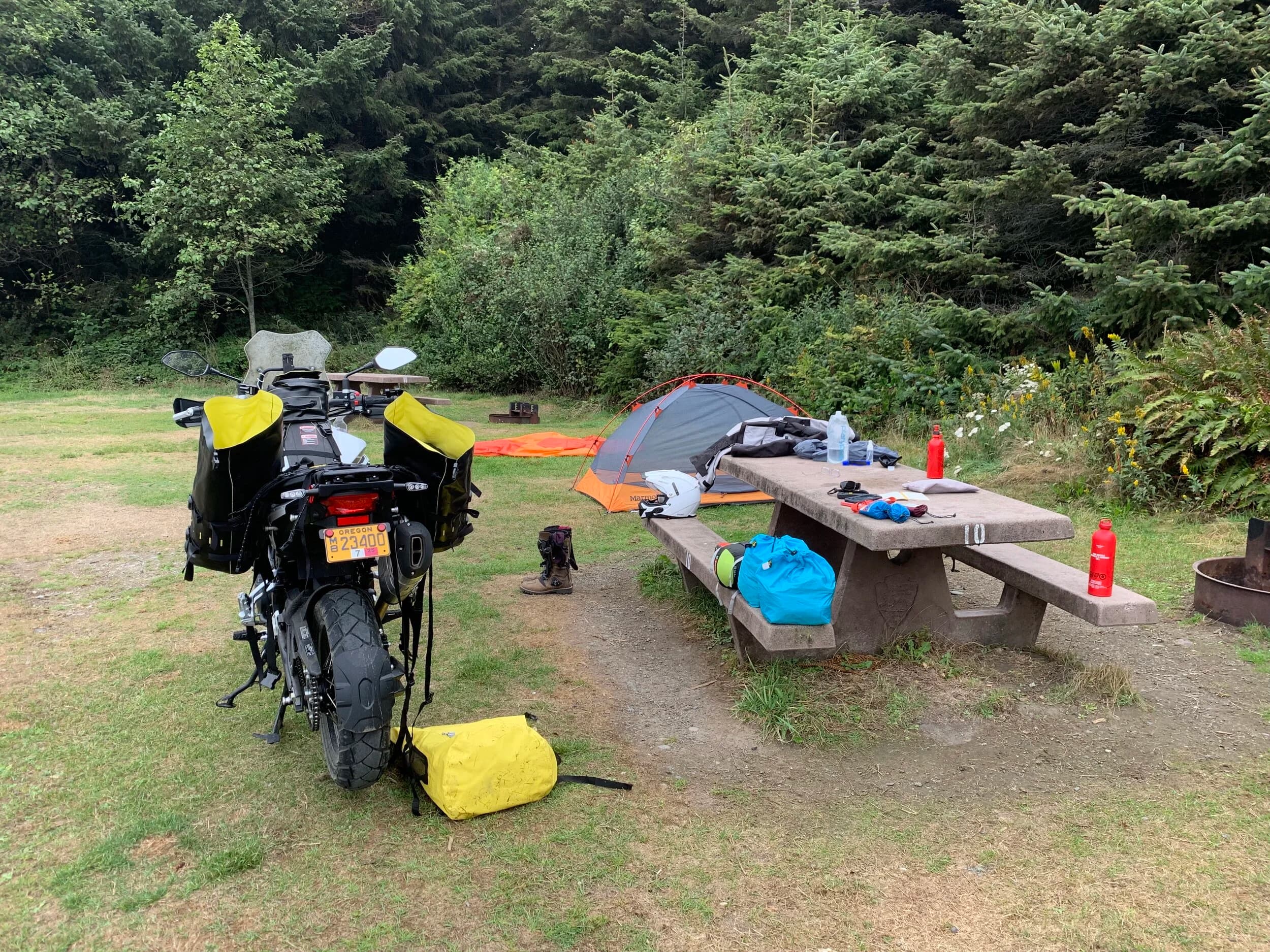 Trip Report: Portland to Olympic Peninsula to Orcas Island
If you follow me on Instagram, you know I purchased a 2021 Benelli TRK502X in July. I just completed my first overnight trip with the new Benelli, doing 7 nights / 8 days from Portland, up the Olympic Peninsula, over to Bellingham and then finally to Orcas Island.
The plan was to camp most or all nights until my last two nights on Orcas, where I had a small waterfront cottage rented right in Orcas Village, where the ferry lands. After three nights of camping, however, I realized I can’t really do the “thin air pad on the ground” thing anymore (I’d be 50 in a week, after all!). My back was killing me and I was not sleeping well, making the following day’s ride less enjoyable at best, and probably also less safe.
So, instead of 5 nights of camping, I did three and then found a cheap motel in Port Angeles, figuring I’d camp the next night and then do my two nights in the cottage. As it happened, most of the next day was rain and the forecast was rain all night and into the morning, so I ended up in a hotel in Bellingham to avoid setting up and breaking down camp in the rain. I can do it. Have done it. But if money is no object and there is lodging available, why be miserable?
The route I planned was intended to get me familiar with the TRK’s manners while allowing for the fact that I’d be riding solo and really didn’t want to get into trouble that I couldn’t get myself out of. The 502X, despite being a 500cc bike, is not light. Curb weight is listed as 518 lbs (dry is 470). So, I favored two lane highways, but included some backcountry single lane roads that were a mix of pavement and gravel.
Here’s my trip report. Day 1Planned / Actual Destination: Cape Disappointment State Park
Planned / Actual Accommodation: Camping
Planned / Actual Miles: 201 / 212
Planned Route: Tigard to Seaside via the Nestucca River Backcountry Byway; Seaside to Cape Disappointment via US 101.
Route NotesI let Google guide me to Carlton from Tigard (home base). On Gaia GPS, I had planned a route that followed the Nestucca River Backcountry Byway from Carlton to Beaver. Unfortunately, there was a detour after McGuire Reservoir (the body of water at the left edge of the right third of the map above) that took me well south down to Bell Mountain along Bald Mountain Rd before heading back north again and rejoining the Nestucca River Rd near Thune Mouintain. Basically, I missed at least half of the scenic route I was hoping for. I wasn’t sure how far the closure went on Nestucca River Rd, and I was still getting the hang of using Gaia to both see where I was, and plan where I wanted to go…so I just followed the signs for the detour. The detour was nice, but it wasn’t the Nestucca River . Most of the route was paved single lane forest road, with a small section of gravel thrown in before the detour.
Once to Beaver, I just rode south on 101 until I saw the signs for Pacific City. Lunch at Pelican Brewery. (I’m not a fan of their new orange grate picnic table outdoor seating.)
After lunch, I rode straight up 101 through Astoria and across to Ilwaco, where I had a reservation to camp at Cape Disappointment. Great spot, right up against the beach (with some trees and brush to break the wind). Camp NotesCape Disappointment was filled mostly with campers pulled by pickup trucks, and my site was nestled between two of them. Most people were friendly. The guy on the north side came over right away to ask about the bike. He’d never seen or heard of Benelli. The guy on the south side came over several times. It’s like he kept looking for excuses to come over and talk more. He even offered me dinner (red beans and rice, with sausage). I accepted. The next morning, he came over with pictures of places I should see in Olympic National Park. The wife of the guy on the north side came over just before I departed for the day’s travels. “Looks like a lot of fun. Nice bike. Reminds me of when we used to backpack. Now we have this thing,” (she gestured to her trailer).
The site itself was great. It was wooded, and sheltered from the beach winds with a thin band of trees and brush, plus a wall of driftwood you had to navigate through and over to get to the beach. The beach itself was gorgeous. Gear NotesI’d read that my trusty MSR Whisperlite Internationale (purchased in 1991) can run on unleaded gasoline just as easily as white gas. Since this kind of moto touring is about going as light and simply as possible, I figured I’d just run unleaded gas instead of bringing white gas. This way, I’d have 1.5 liters of spare gas plus whatever was in my stove bottle in the event that I ran out of gas on the road. Seemed like a great idea.
The reality, as I found out, is that gasoline burns very dirty compared to white gas. It lit, no problem, but the stove was left covered in black soot after a single burn and everything ends up smelling like gasoline. I never realized how much I’d want to smell white gas. So, next trip I’ll ditch the gasoline and go back to white gas.
Also, I threw out my deodorant and body soap before bed. Because I’m using soft bags (not hard aluminum cases) all of my food, toothpaste, and other smelly items need to fit into a small bear canister that fits inside one of my soft bags (keeps rodents out, even if there are no bears). To save space, the stove needs to fit in the bear canister, too. The deodorant and soap simply didn’t fit. So, off they went. Besides, I use Dr. Bronner’s as my dish soap. If I found a shower, I could use that.
Day 2Planned / Actual Destination: South Beach Campground
Planned / Actual Accommodation: Camping
Planned / Actual Miles: 231 / 219
Planned Route: Cape Disappointment up around the Long Beach Peninsula, to South Beach Campground via Raymond, Grayland, Aberdeen, Moclips, Lake Quinault (I skipped the loop around the Long Beach Peninsula)Route NotesToday was a very nice ride. Two lane highway all the way, with a good chunk of it along the coast. I had planned to do a loop up the Long Beach Peninsula, but decided to skip it to save time after spending some time in the morning exploring Cape Disappointment State Park. My destination, South Beach Campground, is first come / first serve and I wasn’t sure how busy it would be, so I didn’t want to arrive too late.
Finding lunch turned out to be a problem. I was avoiding sketchy looking places because the mask wearing seemed to be a problem. I wasn’t looking for conflict. Along the way I discovered the town of Seabrook, which appears to be a vacation shopping mall built specifically to separate you both from reality and your money. Not my kind of place, though I did look to see if there was a place I could eat. Everything looked too fancy for me to roll up in my full moto suit and boots. Where’s a good taco truck when you need one?
I ended up eating in a gas station convenience store (You and I Market) parking lot in Pacific Beach, just up the road from Seabrook with a bunch of day laborers picking up their afternoon tallboys. Gear NotesFor day two, I used Gaia GPS’s route planning feature to set my path to South Beach. It’s quite easy once you figure out the combination of gestures and long-presses (I needed a YouTube video). One caveat is that you either need a data connection (Wi-Fi or mobile data) to be able to do it (if you want the route to snap to a road or trail, which is quite handy), or you need to have downloaded all the map areas and route planning data ahead of time. Ordinarily, this wouldn’t be a problem, but I had brought along two phones: my iPhone (which is my regular phone) for pictures and communication (it would ride in my chest pocket); and Goggle Pixel 3 I’d purchased to use only for navigation (it would be mounted to the handlebars). I don’t have data for the Pixel.
This turned out to be a problem because I hadn’t downloaded all the map areas and route planning data for my trip onto the Pixel (whereas I had downloaded it all to the iPhone). So, I switched to navigating (still with Gaia GPS) on my iPhone and taking pictures with the Pixel for this leg of the trip, hoping I’d get good Wi-Fi at some point which would allow me to download the data I needed onto the Pixel so I could switch back.
This single day of using the iPhone as my navigation device fried the camera. Two days later, Apple published this.
I still really like having two phones on a trip. (I also have a Spot X satellite communicator for off-grid communication.) It’s nice to have one in the pocket that can come out for a quick picture. It’s also nice to have an emergency backup. It would be nice to have a data plan for the nav phone. Short of that, I just need to be better about downloading map areas and routing data ahead of time (and not using my iPhone for nav). Camp NotesSouth Beach Campground is right on the water, and it’s first-come, first-served. The weather was good, and I felt lucky to get a spot. There were several spots available as it turned out. As I was riding around trying to choose which spot to take, there was a couple with a pickup camper waving me in next to them. This was a first. “We ride!” they exclaimed. So that’s where I set up camp.
The guy’s name was Steve Miller. He sells CBD products online. Seems on brand. They were an amazingly friendly couple, actually. Both ride BMW’s and Steve, especially, was really curious and enthusiastic about the TRK. The bike was really turning out to be a conversation starter. He came over several different times while I was setting up camp and making dinner to ask questions or share info about riding groups he’s a part of. It was really quite welcome.
In the morning they gifted me some carrot zucchini bread for breakfast and then broke camp and pulled out well before I did.