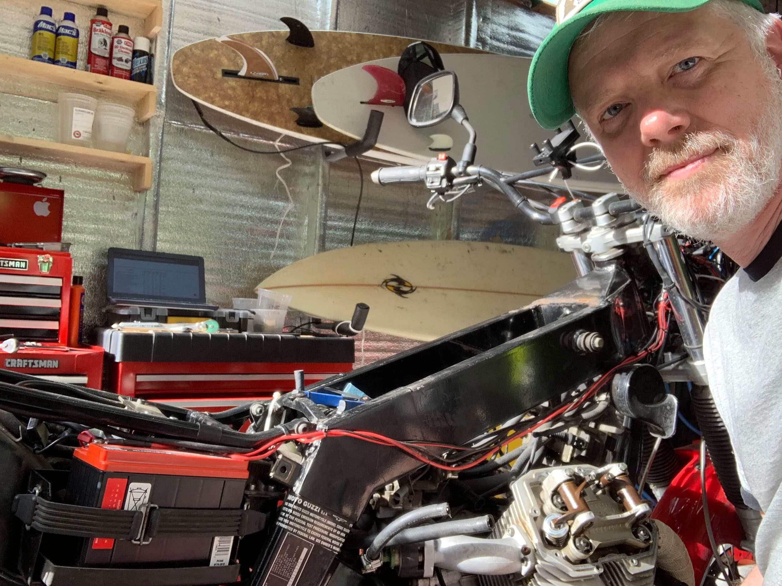 State of the Quota, pt. One
If you’ve read my first post or the About section, you know I’m planning on riding a Moto Guzzi Quota 1100ES on the first several sections of the Nevada BDR (along with my brother on his KLR 650) in spring 2020. There’s a lot of prep to do before then, but let’s start with the State of the Quota.
The bike in question was made in Mandello del Lario, Italy at the historic Moto Guzzi factory. Moto Guzzi, established in 1921, is the oldest European motorcycle works in continuous production. The Quota 1100ES was made from 1998 to 2001 but was only sent to the United States, in very small quantities, for the 1999 and 2000 model years. I can’t find a definitive source, but the consensus seems to be that only about 130 units total were sent to the US. The one I own is model year 2000 and is the only one I’ve ever seen in real life. It’s probably a safe bet that only half of those original US-bound bikes are still on the road. It’s a very small club.
The good news, though, is that, although the frame and body components are entirely unique, the motor and drivetrain are assembled from common Guzzi parts and are easy to come by. That said, it would really be smart to buy a second Quota as a parts donor bike. Some things, like shift levers and body parts, are getting harder to find (and much more expensive). The club is getting smaller.
I acquired my Quota in the spring of 2018 from my buddy Patrick in Seattle who collects, builds and barters all things Moto Guzzi. I’m not sure how or why he had it. He’s not an “adventure” rider. I think he just thought it was cool. Which it is.
The bike needed a bit of work when I bought it and part of the deal was that we’d do that work together, in his garage, before I trailered it back home to Portland. So, over the course of a weekend, we replaced a head that had a stripped out exhaust stud with a spare Patrick had laying around (see note above about collecting and bartering), swapped out the middle muffler for straight-through Y-pipe, changed the fluids, and adjusted the valves.
Sounds all very simple, but there was a hiccup. After installing the replacement head and moving on to reassembly and connection of the accessory components we discovered that there was no place in the new head for the head temp sensor, which is used by the electronic fuel injection (EFI) system. In the original head, there’s a threaded bore into which the threaded end of the brass sensor unit is screwed. No such bore on the donor head.
After some calling around to Patrick’s Moto Guzzi mechanic friends, it was decided that the brass heat sink of the temp sensor simply needs to be in contact with the head somewhere and that would provide enough thermal transfer to give the EFI the engine temp info it needs to adjust fuel delivery properly. So, Patrick drilled some small holes into the cooling fins on the inboard side of the head and lashed the temp sensor assembly to the head sideways, brass to aluminum. It seems to work. It’s been working for two years. All the same it’s not like me to jury-rig something like this, and it bugs me constantly. Even more so now that I’ve admitted my mechanical transgression publicly.
You’ll note in a later post that I have stainless safety wire on my packing list…and you’ll know why.
With that out of the way, here’s a catalog of what’s been done to date and the current state of the Quota. Mods & Repairs To Date Electrical Battery (upgraded to Odyssey AGM) Stator (replaced failing unit)Regulator / Rectifier (retrofit a Drag Specialties Harley Davidson part less finicky about AGM batteries) Headlight (retrofit an MZ Skorpion head - the original is dangerously anemic) Riding / “see me” lights (added)Voltage meter (added to dash) Mechanical Right-side head (replaced with donor)Head temp sensor (bastardized, see above) Middle muffler (replaced with Mistral Y-pipe)Front crank seal (replaced) Exhaust crossover removed, headers wrapped (done by previous owner, these always crack) Running Gear Rear wheel rim (replaced with Sun Rims wheel from a wrecked Quota, found on eBay; the original Excel rears are crack-prone)Tires (Avon Trekriders 50/50 adventure sport)Pinned shift actuator lever to shaft (it kept falling off while I was riding!)AccessoriesUSB charge portPhone mount (Perfect Squeeze from Hondo Garage)Tool tube (from Agri Supply)Barkbusters Heated grips (added by previous owner)
The bike also has OEM Hepco+Becker Moto Guzzi hard bags which, in my opinion, are really made for road travel. I’m considering whether to use them on Nevada BDR trip. Leaning toward no; the mounting hardware makes a good platform for soft luggage, though.
Next post we’ll look at the to-do and wish lists heading into Nevada.