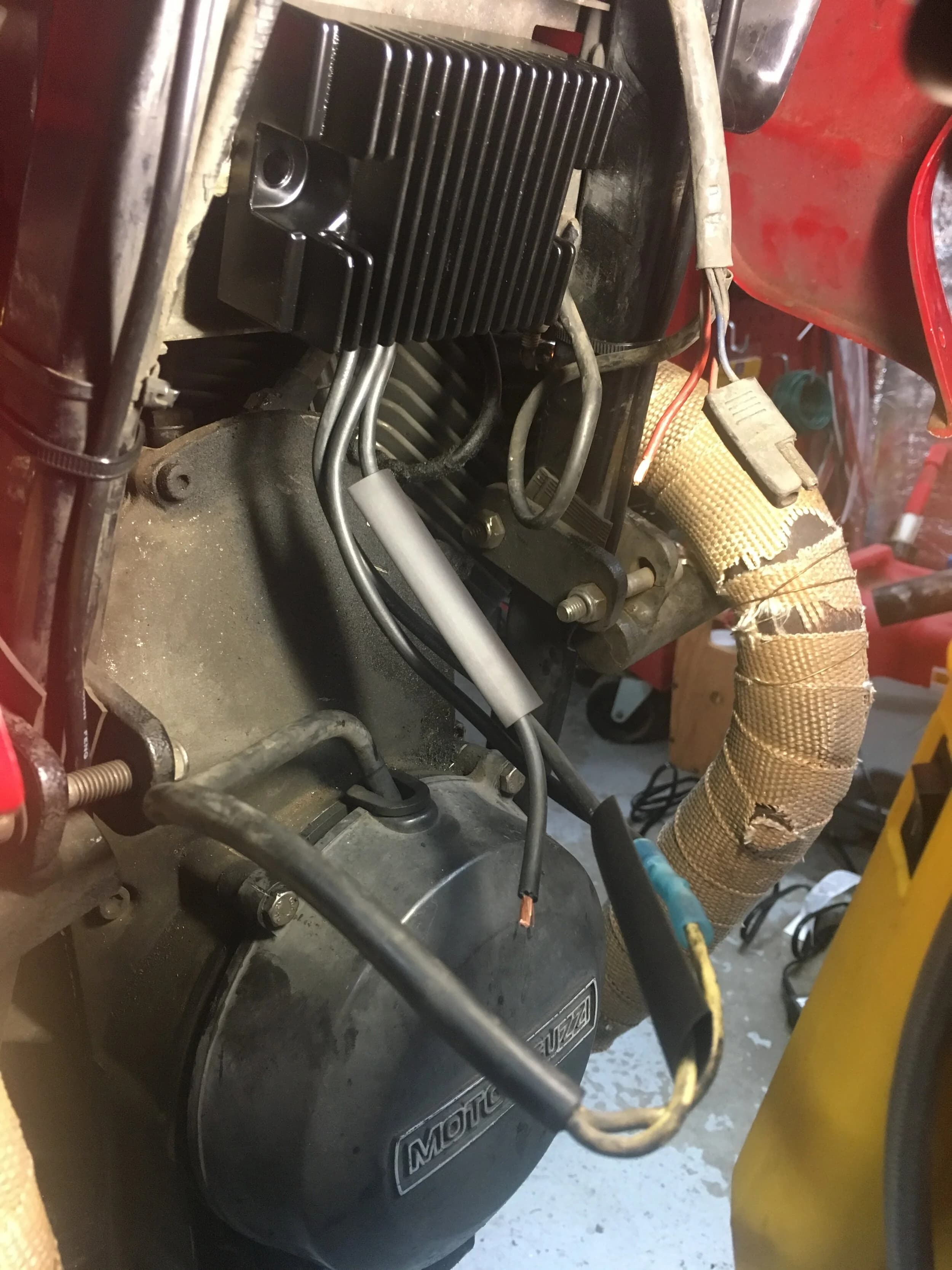State of the Quota, pt. One
If you’ve read my first post or the About section, you know I’m planning on riding a Moto Guzzi Quota 1100ES on the first several sections of the Nevada BDR (along with my brother on his KLR 650) in spring 2020. There’s a lot of prep to do before then, but let’s start with the State of the Quota.
The bike in question was made in Mandello del Lario, Italy at the historic Moto Guzzi factory. Moto Guzzi, established in 1921, is the oldest European motorcycle works in continuous production. The Quota 1100ES was made from 1998 to 2001 but was only sent to the United States, in very small quantities, for the 1999 and 2000 model years. I can’t find a definitive source, but the consensus seems to be that only about 130 units total were sent to the US. The one I own is model year 2000 and is the only one I’ve ever seen in real life. It’s probably a safe bet that only half of those original US-bound bikes are still on the road. It’s a very small club.
The good news, though, is that, although the frame and body components are entirely unique, the motor and drivetrain are assembled from common Guzzi parts and are easy to come by. That said, it would really be smart to buy a second Quota as a parts donor bike. Some things, like shift levers and body parts, are getting harder to find (and much more expensive). The club is getting smaller.
I acquired my Quota in the spring of 2018 from my buddy Patrick in Seattle who collects, builds and barters all things Moto Guzzi. I’m not sure how or why he had it. He’s not an “adventure” rider. I think he just thought it was cool. Which it is.
The bike needed a bit of work when I bought it and part of the deal was that we’d do that work together, in his garage, before I trailered it back home to Portland. So, over the course of a weekend, we replaced a head that had a stripped out exhaust stud with a spare Patrick had laying around (see note above about collecting and bartering), swapped out the middle muffler for straight-through Y-pipe, changed the fluids, and adjusted the valves.
Sounds all very simple, but there was a hiccup. After installing the replacement head and moving on to reassembly and connection of the accessory components we discovered that there was no place in the new head for the head temp sensor, which is used by the electronic fuel injection (EFI) system. In the original head, there’s a threaded bore into which the threaded end of the brass sensor unit is screwed. No such bore on the donor head.
After some calling around to Patrick’s Moto Guzzi mechanic friends, it was decided that the brass heat sink of the temp sensor simply needs to be in contact with the head somewhere and that would provide enough thermal transfer to give the EFI the engine temp info it needs to adjust fuel delivery properly. So, Patrick drilled some small holes into the cooling fins on the inboard side of the head and lashed the temp sensor assembly to the head sideways, brass to aluminum. It seems to work. It’s been working for two years. All the same it’s not like me to jury-rig something like this, and it bugs me constantly. Even more so now that I’ve admitted my mechanical transgression publicly.
You’ll note in a later post that I have stainless safety wire on my packing list…and you’ll know why.
With that out of the way, here’s a catalog of what’s been done to date and the current state of the Quota. Mods & Repairs To Date Electrical Battery (upgraded to Odyssey AGM) Stator (replaced failing unit)Regulator / Rectifier (retrofit a Drag Specialties Harley Davidson part less finicky about AGM batteries) Headlight (retrofit an MZ Skorpion head - the original is dangerously anemic) Riding / “see me” lights (added)Voltage meter (added to dash) Mechanical Right-side head (replaced with donor)Head temp sensor (bastardized, see above) Middle muffler (replaced with Mistral Y-pipe)Front crank seal (replaced) Exhaust crossover removed, headers wrapped (done by previous owner, these always crack) Running Gear Rear wheel rim (replaced with Sun Rims wheel from a wrecked Quota, found on eBay; the original Excel rears are crack-prone)Tires (Avon Trekriders 50/50 adventure sport)Pinned shift actuator lever to shaft (it kept falling off while I was riding!)AccessoriesUSB charge portPhone mount (Perfect Squeeze from Hondo Garage)Tool tube (from Agri Supply)Barkbusters Heated grips (added by previous owner)
The bike also has OEM Hepco+Becker Moto Guzzi hard bags which, in my opinion, are really made for road travel. I’m considering whether to use them on Nevada BDR trip. Leaning toward no; the mounting hardware makes a good platform for soft luggage, though.
Next post we’ll look at the to-do and wish lists heading into Nevada.